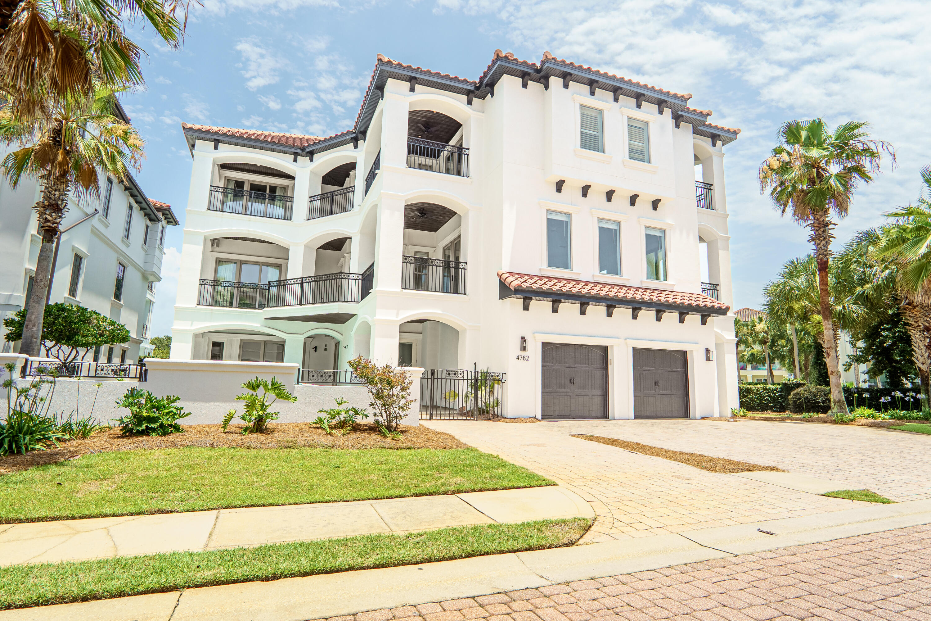 Excellent REO opportunity to own an extraordinary coastal estate located within Destiny by the Sea, one of Destin's most exclusive 24/7 secured, gated communities. For that savvy investor looking for a short-term rental, this expansive home sleeps 24 and offers a proven footprint for high-capacity guest stays. The property features 7 bedrooms, 7.5 bathrooms, and 5,595 sq ft of living space, highlighted by large balconies and a private saltwater pool with a waterfall feature. The highly functional layout includes a large open kitchen with island seating, an elevator, two dedicated bunk rooms, a home movie room, a billiard room, and a foosball area. Recent updates include a freshly painted interior and exterior. Located just a short walk from the luxurious community pool and private beach access, this property is being sold fully furnished, as-is, where-is. Buyer to verify all dimensions, square footage, HOA rules, and rental regulations.