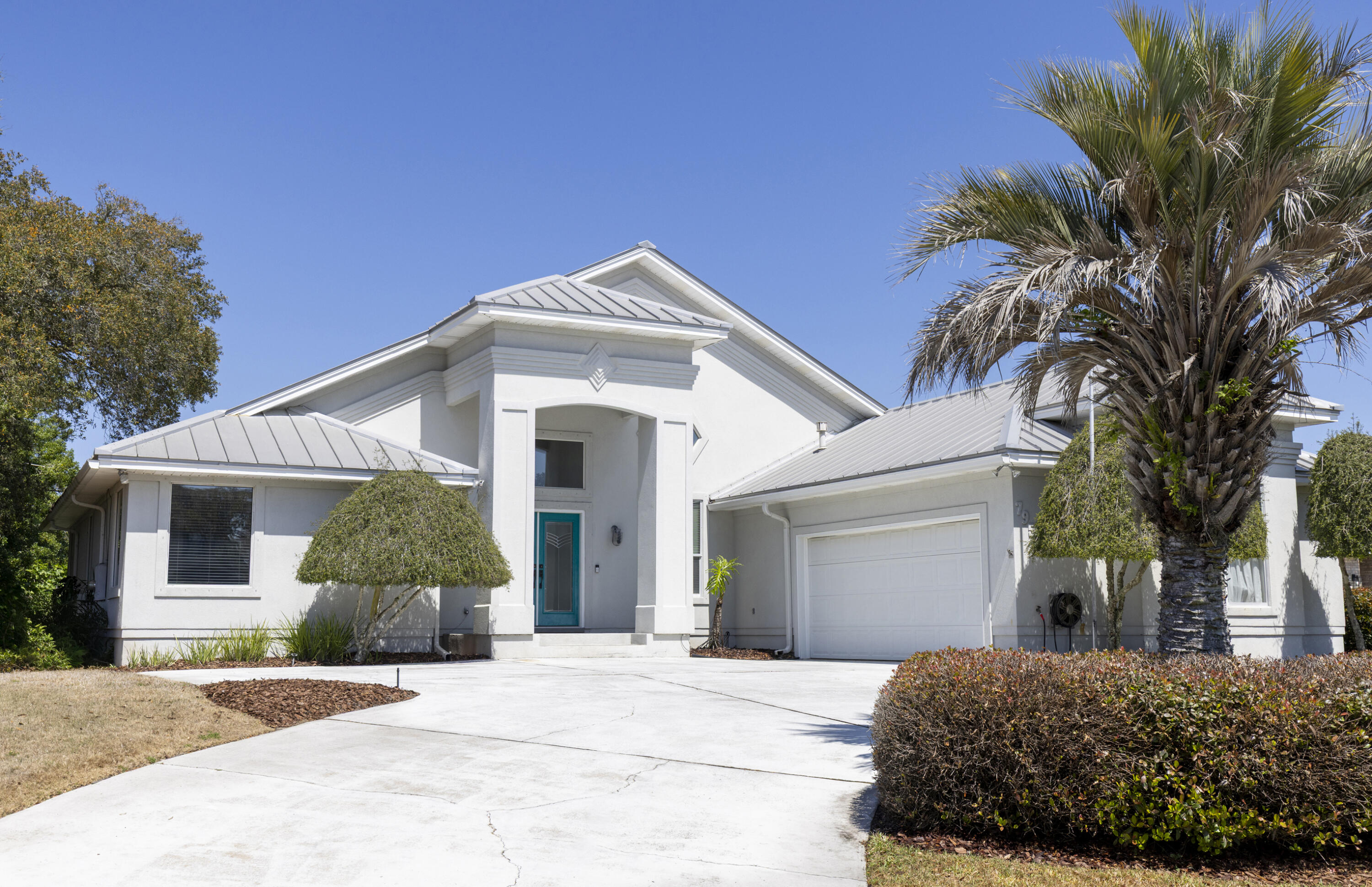 One-owner waterfront home located in the desirable Lake Pointe subdivision, perfectly positioned on Lake Lorraine with direct access to Choctawhatchee Bay and just minutes from Crab Island. This spacious 5 bed/3-bath home offers an open-concept design filled with natural light, highlighted by vaulted ceilings and expansive windows that showcase beautiful water views.  The main living area features multiple doors leading out to a large deck, ideal for indoor-outdoor living and entertaining. The kitchen is open and inviting with a center island, gas cooktop, breakfast bar, a pantry and ample counter and cabinet space.  The main-level Master Suite includes a well-appointed ensuite bath with double vanities, tile flooring, walk-in shower, and a garden tub, along with generous closet space. An additional bedroom and full bath are also located on the main floor.  Downstairs, you'll find three additional bedrooms and a full bath, providing plenty of space for family or guests.  From here, step outside to enjoy the enclosed in-ground pool and hot tub, along with a private pathway leading to the boat dock complete with lift--perfect for enjoying waterfront living at its finest