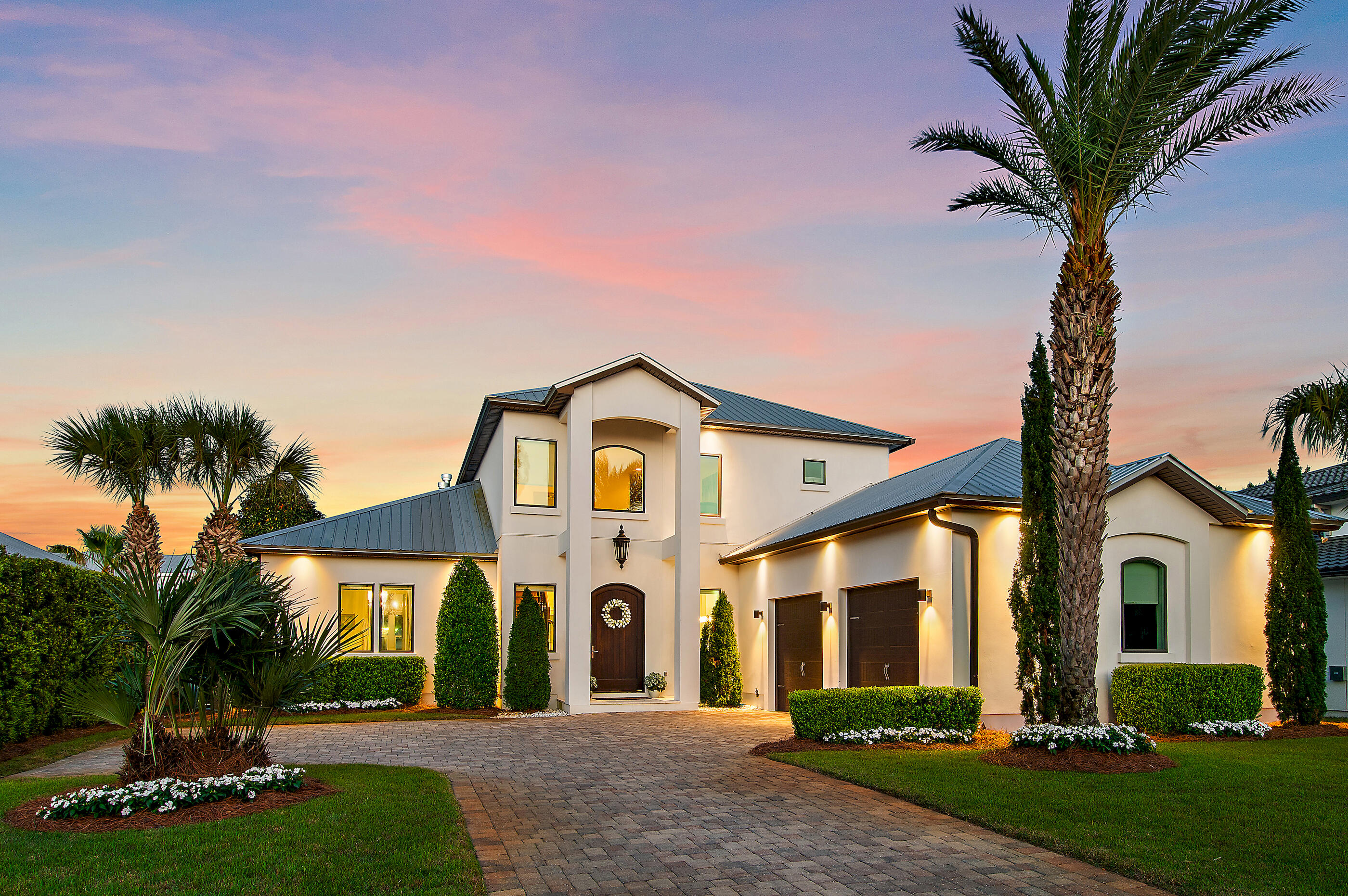 Nestled within the gated community of Cypress Breeze along scenic 30A, this exceptional residence blends refined design with superior craftsmanship to create a truly timeless retreat. From the moment you enter, you're welcomed by high ceilings and a statement-making staircase that sets the tone for the home's sophisticated aesthetic. The thoughtfully designed floor plan offers seamless flow, ideal for both everyday living and effortless entertaining. The great room serves as the heart of the home, anchored by a stunning gas fireplace and opening gracefully into an elegant dining space adorned with designer lighting. Step outside through expansive glass French doors into your private outdoor oasis. Surrounded by lush landscaping, the open-air living area invites relaxation, while the fully equipped summer kitchen and bar provide the perfect setting for hosting unforgettable gatherings.

Back inside, the chef's kitchen is a true showpiece, featuring a coveted gas Wolf range, Sub-Zero refrigeration, a beverage center, an ice maker, a walk-in pantry, and premium finishes throughout. Stone countertops and luxury fixtures further elevate the space.

The main-level primary suite offers a serene escape, complete with a spa-inspired en-suite bath showcasing a freestanding soaking tub, spacious glass-enclosed shower, and dual vanities.

Additional conveniences on the first floor include a stylish powder room, generous laundry space, an oversized two-car garage, and a dedicated workshop.

Upstairs, you'll find a private guest suite, two additional bedrooms, a beautifully appointed full bath, and a fully equipped media room--perfect for movie nights, game days, and entertaining. A wet bar and additional storage enhance the functionality of this versatile space.

Residents of Cypress Breeze enjoy a secure, gated lifestyle with resort-style amenities, including an expansive community pool. Ideally located just moments from the beach, as well as 30A's renowned dining, shopping, and entertainment, this home offers the ultimate blend of luxury, comfort, and convenience.