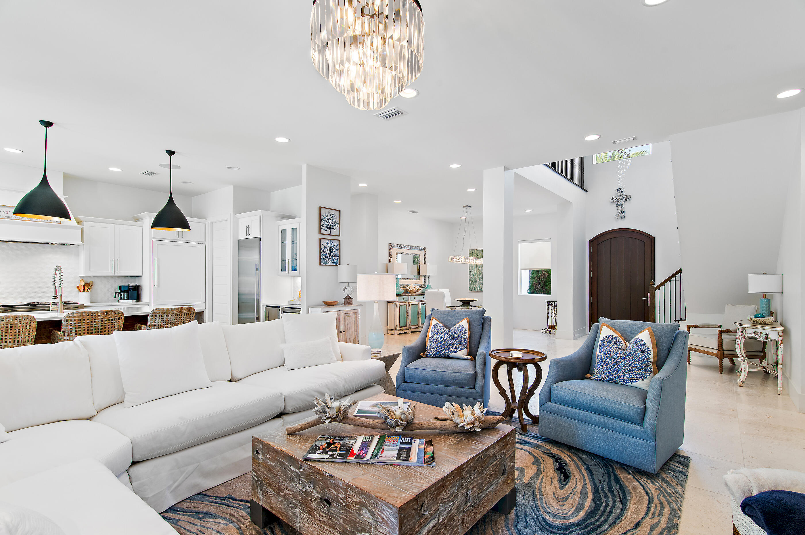 Located within the exclusive gated community of Cypress Breeze along the iconic 30A corridor, this exceptional residence showcases timeless architecture, refined finishes, and impeccable craftsmanship. A grand foyer with soaring ceilings and a striking staircase creates an unforgettable first impression, setting the stage for the home's elegant design. Thoughtfully crafted for both comfortable everyday living and sophisticated entertaining, the open-concept floor plan flows seamlessly from one space to the next. At the heart of the home, the inviting great room features a beautiful gas fireplace and transitions effortlessly into a stylish dining area highlighted by designer lighting. Expansive French glass doors open to a private outdoor retreat, offering the perfect setting to relax, entertain, and enjoy the coastal lifestyle. Surrounded by lush landscaping, the open-air living area invites relaxation, while the fully equipped summer kitchen and bar provide the perfect setting for hosting unforgettable gatherings.

Back inside, the chef's kitchen is a true showpiece, featuring a coveted gas Wolf range, Sub-Zero refrigeration, a beverage center, an ice maker, a walk-in pantry, and premium finishes throughout. Stone countertops and luxury fixtures further elevate the space.

The main-level primary suite offers a serene escape, complete with a spa-inspired en-suite bath showcasing a freestanding soaking tub, spacious glass-enclosed shower, and dual vanities.

Additional conveniences on the first floor include a stylish powder room, generous laundry space, an oversized two-car garage, and a dedicated workshop.

Upstairs, you'll find a private guest suite, two additional bedrooms, a beautifully appointed full bath, and a fully equipped media room--perfect for movie nights, game days, and entertaining. A wet bar and additional storage enhance the functionality of this versatile space.

Residents of Cypress Breeze enjoy a secure, gated lifestyle with resort-style amenities, including an expansive community pool. Ideally located just moments from the beach, as well as 30A's renowned dining, shopping, and entertainment, this home offers the ultimate blend of luxury, comfort, and convenience.