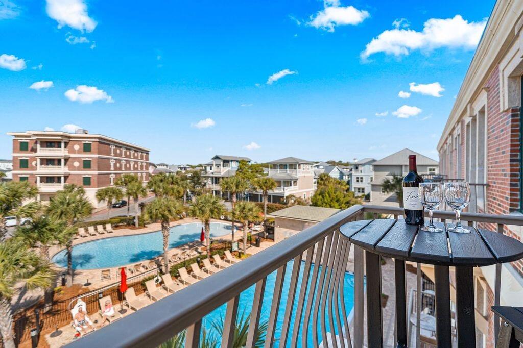 Rare top-floor end unit in The Village of South Walton, ideally positioned between Rosemary Beach and Alys Beach along Scenic Highway 30A. Privately situated within the community and not directly above the commercial spaces, this beautifully updated 3-bedroom, 2-bath coastal retreat offers exceptional privacy, natural light, and turnkey convenience in one of the most desirable locations on the east end of 30A.
Featuring soaring 11-foot ceilings, abundant windows unique to end units, refinished travertine flooring in the main living areas, and tile plank flooring throughout the bedrooms, the residence blends elevated coastal design with a relaxed beachside atmosphere. Filled with natural light, the open-concept floor plan creates an airy and welcoming living space ideal for entertaining or  unwinding after a day on the beach.
Sold fully furnished and completely rental ready, this impeccably maintained condominium has never been rented by the current owner and reflects exceptional pride of ownership throughout. The spacious kitchen features updated appliances and comes fully stocked with dishes, cookware, glassware, and utensils, making ownership or vacation rental setup effortless from day one.
The main living area is anchored by a 75-inch television, while each guest bedroom includes 55-inch TVs. Comfortably sleeping seven guests, the property also includes a full-size washer and dryer, two separate owner storage closets, custom closet shelving systems, and a dedicated dehumidifier for enhanced climate control and long-term property care.Step outside onto the private top-floor balcony overlooking the resort-style pool -- the perfect setting for morning coffee, sunset cocktails, or simply enjoying the coastal breeze. The spacious primary suite offers a peaceful retreat with an en-suite bath, while two additional guest bedrooms provide flexible accommodations for family and guests.
Owners and guests enjoy access to resort-style pools, spa, fire pit, seasonal entertainment, boutique shopping, dining, coffee shops, bike rentals, private deeded beach access, and convenient tram service to the Gulf's sugar-white sand beaches and emerald waters. The scenic 30A walking and biking path is located directly outside the community.
Whether you're searching for a primary residence, second home, or investment opportunity, this top-floor end unit offers a rare combination of privacy, location, light, and lifestyle in the heart of 30A. HOA fees include internet, cable TV, water, sewer, trash, grounds maintenance, and parking.