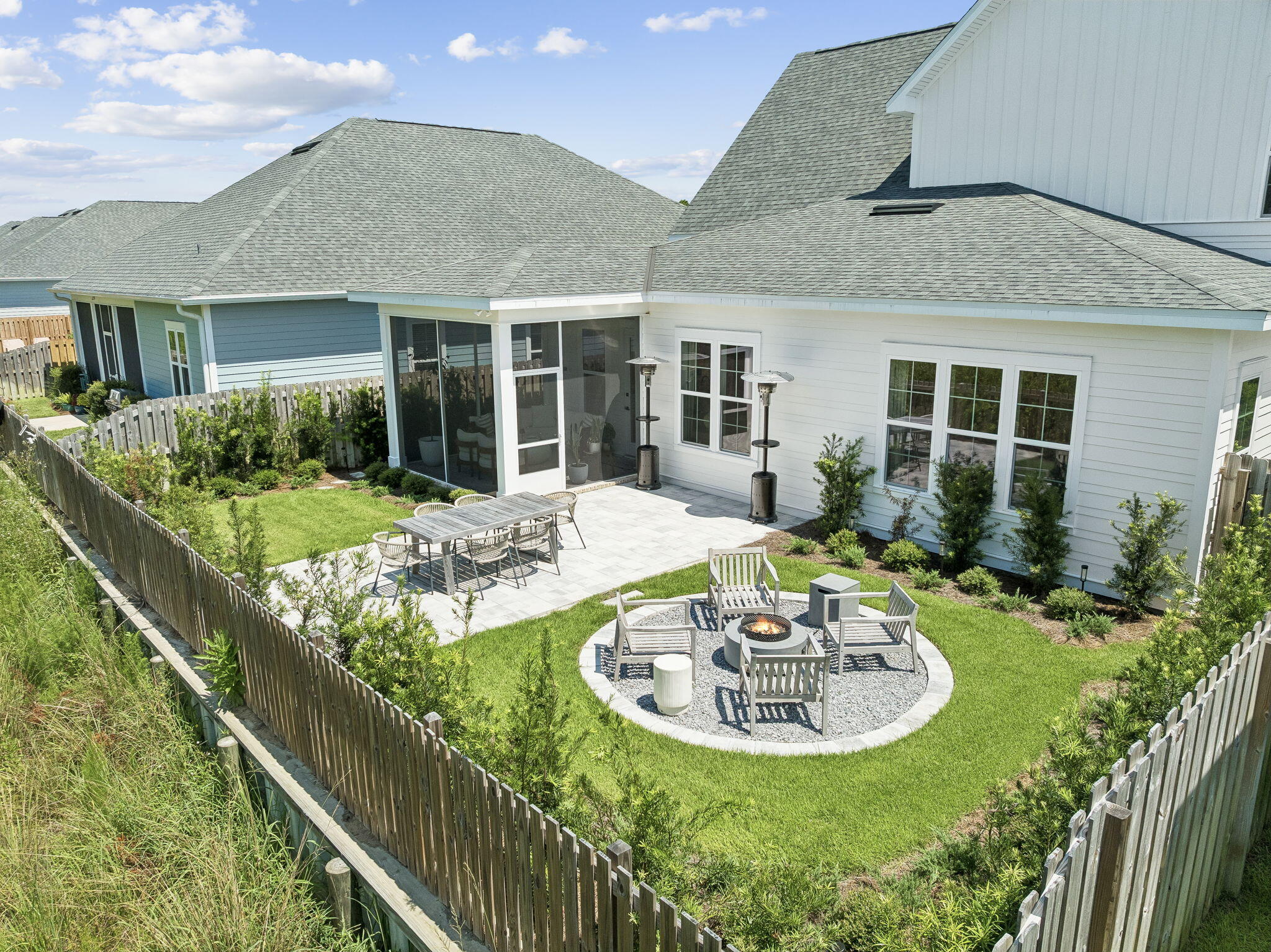 Ideally positioned in the Longleaf Phase of WaterSound Origins, 215 Suwannee Drive offers the perfect blend of convenience, style, and privacy. Located near the front of the community, homeowners enjoy quick access to Highway 98, Publix, dining, shopping, and all the amenities that make the Origins lifestyle so desirable. Built just 2 years ago and impeccably maintained, this thoughtfully designed home features 4 bedrooms, a spacious LOFT, and 3.5 bathrooms, including a 1st-floor primary suite for comfortable everyday living.
Inside, wide-plank luxury vinyl flooring in a warm neutral tone provides the timeless look of hardwoods while creating a bright, cohesive backdrop throughout the home. The center-island kitchen is designed for both entertaining and functionality, showcasing Bosch appliances, a 5-burner gas range, Zephyr range hood, and a generously sized walk-in pantry complete with custom wood shelving and storage cubbies. Black hardware throughout the home adds a sophisticated designer touch, while custom lighting and drapery elevate each space.
The open-concept living area is filled with natural light thanks to an abundance of windows and offers ample room for a large sectional along with additional seating. Pre-wiring for surround sound enhances the home's entertainment capabilities.
Upstairs, the versatile LOFT provides additional living space and includes thoughtful storage features, including a linen closet with wood shelving and extra storage space within the HVAC closet.
Step outside to enjoy the screened porch finished with heirloom brick pavers, overlooking a spacious backyard with a paver patio and cozy FIREPIT area. Backing to a serene wooded preserve, the property offers exceptional privacy along with opportunities to enjoy both sunrise and sunset views from your own backyard retreat.
Combining modern finishes, functional design, abundant storage, and a prime location within WaterSound Origins, 215 Suwannee Drive presents an exceptional opportunity to enjoy one of the area's most desirable communities.