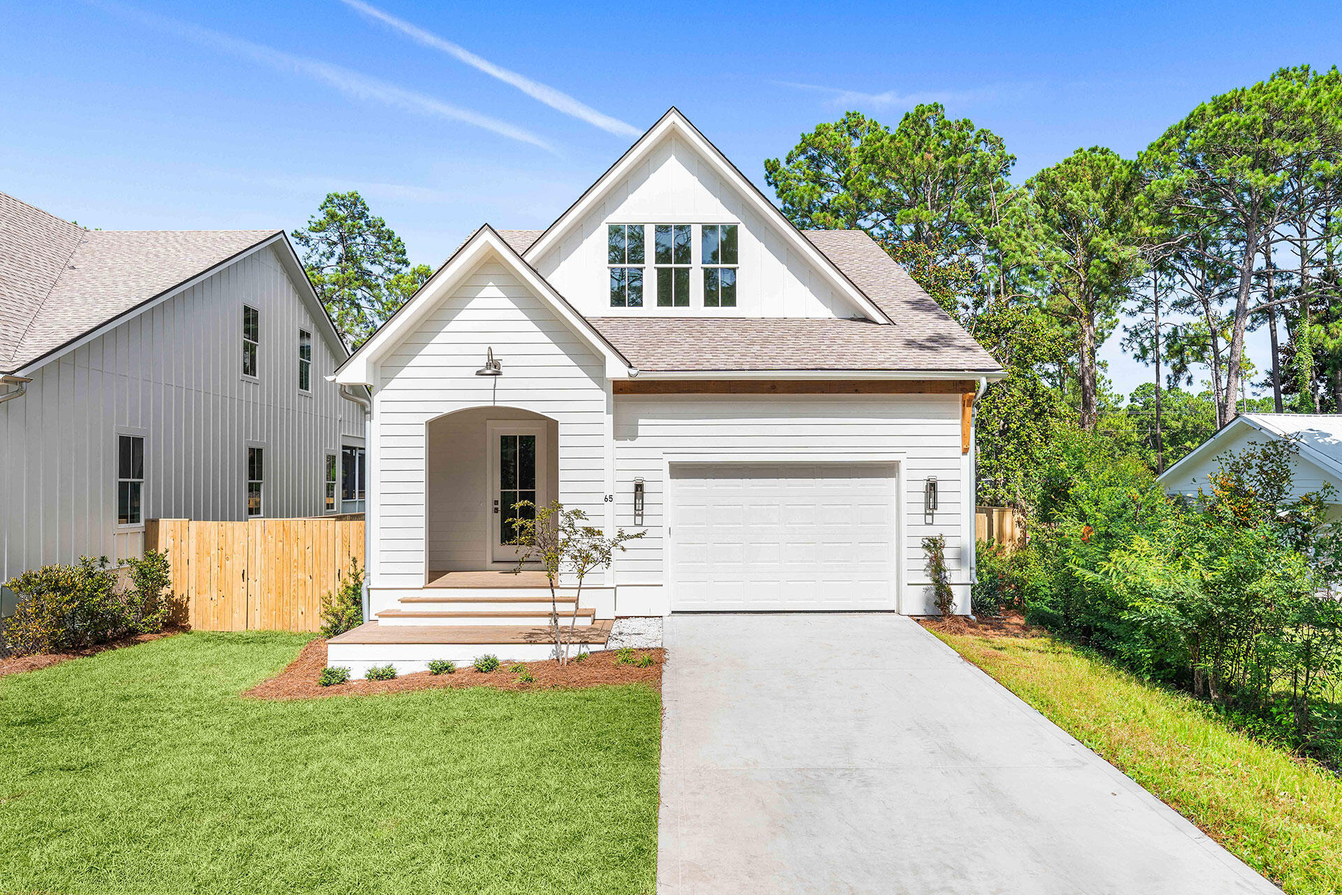 Brand new construction in the heart of Santa Rosa Beach, 65 K Street offers the perfect blend of quality craftsmanship, thoughtful design, and everyday convenience just minutes from 30A and the beach. Built by Borges Brooks Builders, a renowned local builder known for quality and attention to detail, this stunning two-story home features 4 bedrooms, 4.5 bathrooms, 2,029 heated and cooled square feet, a builder warranty, and a functional layout designed for both comfort and style.

The first floor welcomes you with 10-foot ceilings throughout, engineered hardwood flooring, elevated finishes, and a spacious primary suite complete with its own ensuite bathroom. The kitchen is beautifully appointed with quartz countertops and opens seamlessly to the main living and dining areas, creating an easy flow for everyday living or entertaining. A convenient half bath serves the main level, while the screened-in rear porch overlooks the fenced backyard, offering a comfortable outdoor space to relax and enjoy the Florida lifestyle. Upstairs, you'll find three additional bedrooms, each with its own private ensuite bathroom, providing ideal accommodations for family, guests, or flexible use as an office or bunk space. The second floor features 9-foot ceilings throughout, with one front bedroom showcasing a vaulted 10-foot ceiling beneath the charming front dormer, adding character, natural dimension, and architectural appeal. The home's exterior showcases Hardie board siding, with lap siding across the front and board and batten along the sides, along with a concrete driveway, one-car garage, completed landscaping, and an irrigation system.

Located just a short drive to Ed Walline Beach Access, Gulf Place, and Scenic Highway 30A, this home places you close to some of the area's best beaches, restaurants, shopping, and entertainment. Enjoy the convenience of Santa Rosa Beach living with easy access west toward Miramar Beach, Sandestin, and Destin, or east toward Seaside, WaterColor, Rosemary Beach, and Panama City Beach. With brand new construction, ensuite bedrooms throughout, quality finishes, and a prime location near 30A, 65 K Street is a beautiful opportunity in one of Northwest Florida's most desirable coastal communities.