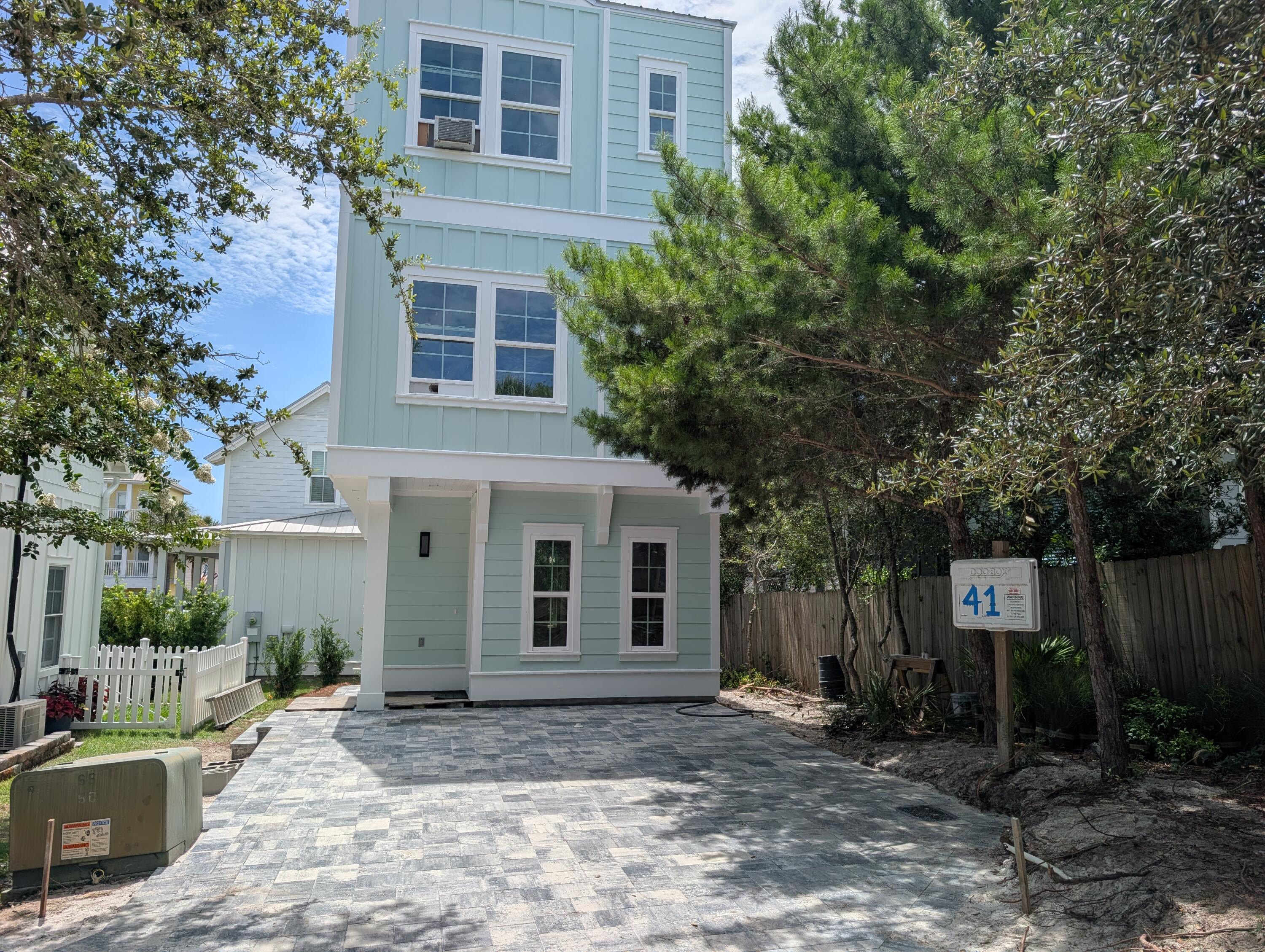 Introducing a brand new luxury coastal retreat in the Villages of Blue Mountain Beach on iconic 30A -- designed for buyers seeking a high-performing investment property, second home, or full-time beach residence with premium craftsmanship and low-maintenance ownership. 
Located in a gated, short-term rental friendly community in Flood Zone X, this newly constructed 3 bedroom, 2.5 bathroom home blends modern elegance with thoughtful functionality just minutes from the sugar-white sands of the Emerald Coast.
Inside, the residence features a plethora of windows that flood the home with natural light while showcasing Gulf views from the third floor. High-end finishes include white oak flooring and stairs, quartz with gold streaks countertops, premium stainless steel appliances, gold fixtures, gold handles,  illuminated vanity mirrors, sleek glass showers with rainfall ceiling shower heads, custom wood shelving throughout every closet, solid wood interior doors, and substantial custom trim work creating a refined luxury feel rarely found in this price point.
Built for durability and efficiency, the home offers spray foam insulation, a concrete block foundation, tankless water heater, quality HVAC system, paver driveway, 9-foot ceilings, wire rail systems to maximize openness, washer and dryer included, and an elegant Alabaster color palette for timeless coastal design. The outdoor living space was intentionally designed to elevate the guest experience and maximize rental appeal, featuring a private outdoor shower, paver patio area, and electrical hookups ready for a custom fireplace, ambient lighting, outdoor kitchen, or waterfall garden feature.
Residents and guests enjoy resort-style amenities including a community pool, fitness center, mini golf, golf cart parking, grilling area, and walkability to local favorites including Mimmo's, coffee shops, ice cream, and wellness stores directly in front of the community.
With comparable homes already generating approximately $65K-$75K annually in rental income -- despite offering fewer upgrades and less refined finishes -- this property presents a compelling opportunity for buyers seeking strong income potential paired with long-term appreciation along 30A.
New construction, luxury finishes, lower maintenance costs, energy-efficient systems, and a prime Blue Mountain Beach location make this an exceptional opportunity entering peak season on 30A.