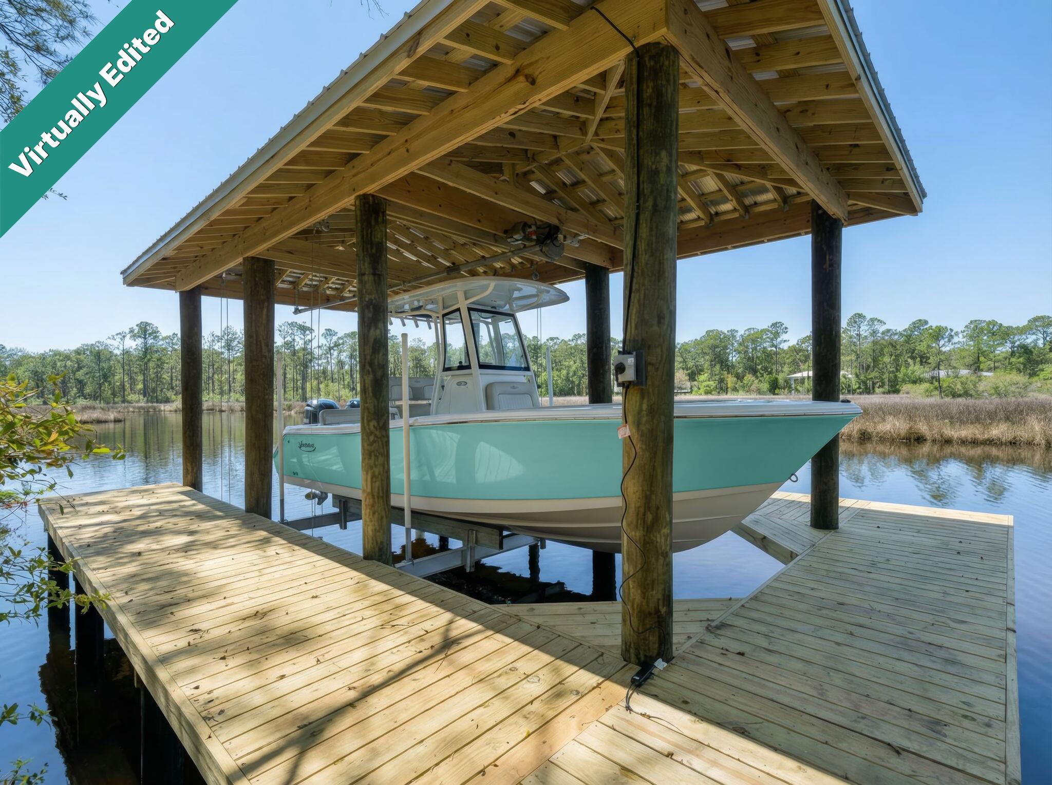 Wake up to the sound of still water and birdsong on this breathtaking bayou-front property, with direct access to Choctawhatchee Bay right outside your back door. Tucked away on a lushly wooded .70-acre lot, this is the kind of rare, unspoiled waterfront setting that's nearly impossible to find in Santa Rosa Beach -- mature trees, total privacy, and stunning water views in every direction. Never-lived-in and built in 2025, this gorgeous 5-bedroom, 3-bath home delivers 3,129 square feet of coastal craftsmanship, complete with a covered boat lift/dock, covered porch, 2-car garage, and designer finishes throughout. Launch from your backyard,  fish from your own dock, or simply sit and watch the bayou come alive, (even dolphins have been spotted)-- this is peaceful, private waterfront living at its absolute finest. Just minutes from 30A beaches and the sugar white sand! From the moment you arrive, you'll be captivated by the home's inviting presence, new construction quality, and thoughtfully designed layout that blends comfort, function, and modern coastal style.Step inside to a light-filled open-concept floor plan featuring a welcoming foyer, a formal dining room, and a dedicated breakfast room perfect for both everyday living and entertaining. The expansive living area flows seamlessly into a chef-inspired kitchen with brand-new appliances, modern cabinetry, and premium finishes.
A versatile bonus flex space offers the perfect opportunity for a home office, study, or media room, providing flexibility for today's lifestyle needs.
The spacious primary suite offers a private retreat with spa-like features, while four additional bedrooms provide ample space for family, guests, or multigenerational living--all finished with clean, modern design and high-quality craftsmanship throughout.
Enjoy true Florida waterfront living with both a large covered front porch and an expansive covered back porch, ideal for relaxing, entertaining, and enjoying peaceful water views and coastal breezes. The backyard flows naturally toward your private boat dock with direct access to the bay, making boating, fishing, paddle boarding, and sunset cruises effortless.
Set on almost an expansive private lot, this property offers exceptional room for a future pool, outdoor kitchen, or custom outdoor oasis. Newly Installed boat dock and lift for deep water access to the bay. Please see the home listed at 769 Old Ferry to view the home with furnishings.