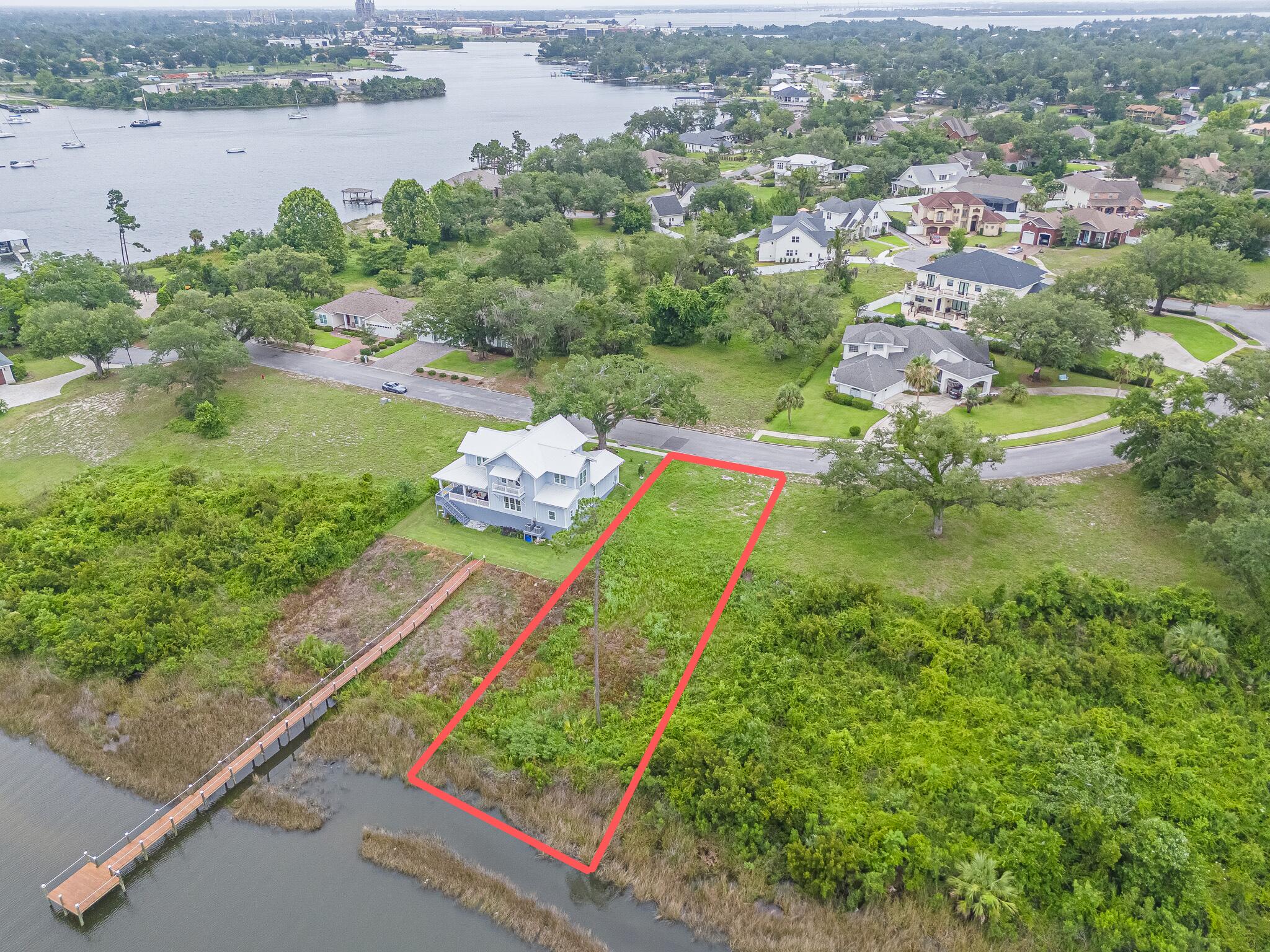 Build your dream home on this exceptional 0.365-acre waterfront homesite in the highly sought-after Cove Pointe community of Panama City. Nestled along the shores of Watson Bayou, this beautiful lot offers access to a navigable waterway leading directly to St. Andrews Bay, the Intracoastal Waterway, and the Gulf of Mexico, making it an ideal location for boating enthusiasts. Known for its mature hardwood trees, elevated topography, and charming waterfront setting, Cove Pointe is one of Panama City's most desirable neighborhoods in Panama City. Residents enjoy a peaceful coastal lifestyle while being just minutes from downtown Panama City, marinas, dining, shopping, medical facilities, and the St. Andrews Bay Yacht Club. Whether you're planning a custom primary residence, vacation home, or waterfront retreat, this rare homesite presents an outstanding opportunity to build in an established community that perfectly blends natural beauty, convenience, and access to some of the area's best boating and waterfront amenities.