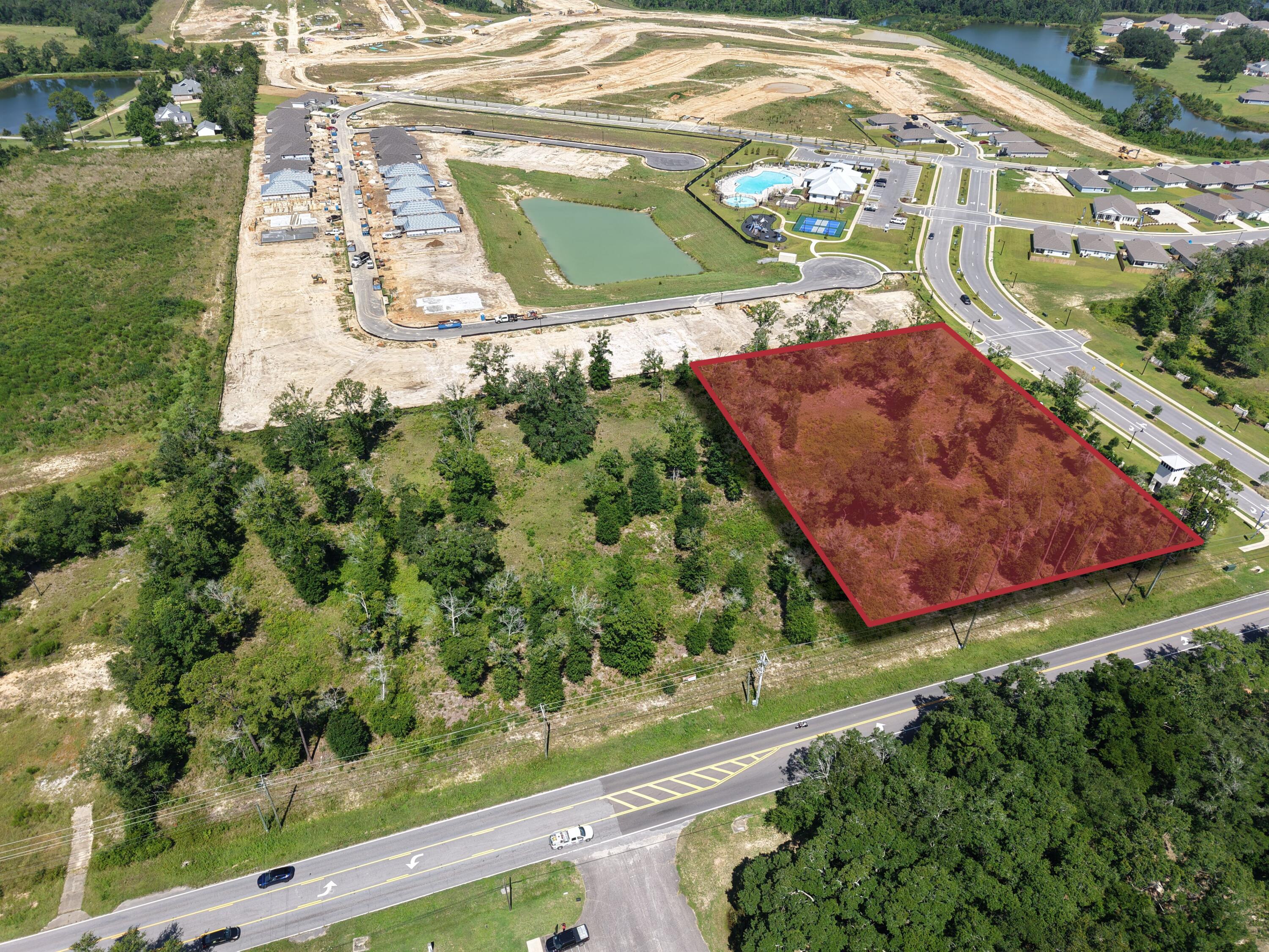 Situated in the rapidly expanding city of Pace, FL, this hard corner parcel is well-positioned to leverage its location along the primary commuter arterial of Woodbine Road and at the head of the +700-home Lakes of Woodbine subdivision. Measuring approximately 265'x315', zoned HCD and with all necessary utilities available to the site, the property is development-ready. As a part of the larger Pensacola MSA, the city of Pace has been a leading market for population growth and development. By extension, Santa Rosa County has seen tremendous growth in terms of new large employer growth, as well as being the primary destination for suburban residents working in the Pensacola market. +/-2.2 Acres of Unimproved Commercial Land - development-ready greenfield site Prime Hard Corner Location at Woodbine Road, the primary commuter arterial in Pace, FL Fronting the Entrance to the 700+ Home Lakes of Woodbine Subdivision - built-in daily traffic and rooftops Zoning: HCD (Highway Commercial District) - supports a wide range of commercial uses All Utilities Available to Site Traffic Counts: +/-21,709 AADT on Woodbine Road Excellent Visibility & Access with strong commuter exposure Surrounded by Expanding Residential Communities and New Commercial Growth