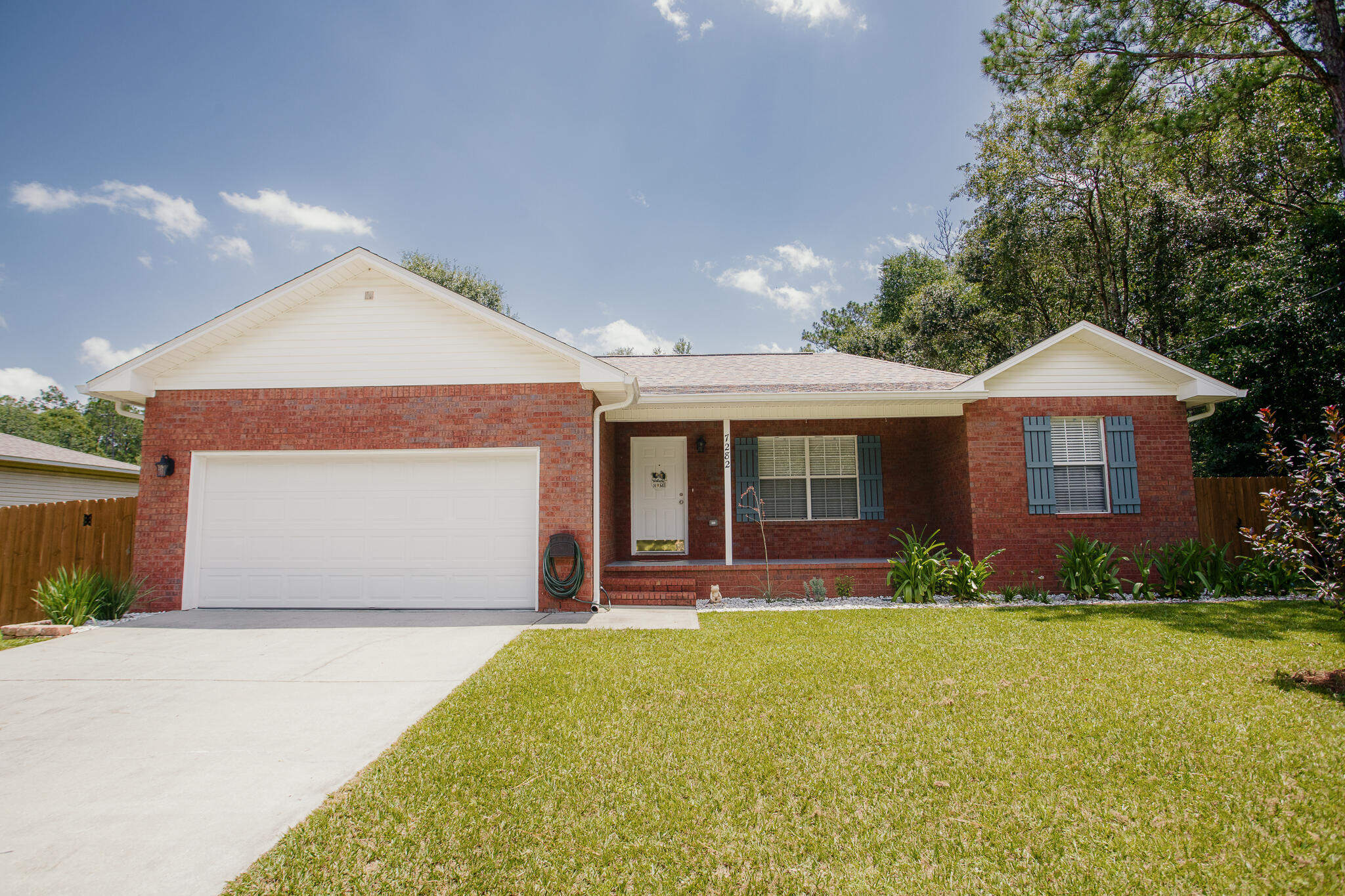 Welcome home to this charming and beautifully maintained 3 bedroom/2 bath split floor plan home.   Home is ideally situated in a peaceful country setting just about 30 minutes from the beautiful Gulf Coast beaches.  Conveniently located near Whiting Field , this property offers the tranquility of country living while keeping shopping and dining within easy reach.  Major improvements include:  A NEW ROOF IN 2022, HVAC IN 2019, WATER HEATER 2023, GUTTERS 2023 AND FRESHLY PAINTED INTERIOR 2026.   THE KITCHEN HAS ALSO BEEN REFRESHED WITH A WHIRLPOOL STOVE AND REFRIGERATOR IN 2026. WHILE THE WASHER/DRYER AND DISHWASHER WERE REPLACED IN 2022. An attic for extra storage.  
Outside is the beautiful flat yard which is perfect for a garden.  Plus, you'll appreciate the 8'  double gates to pull in a  boat or RV.  
This is an amazing all brick house which would make a wonderful home!! Don't miss your opportunity to own it!!!
