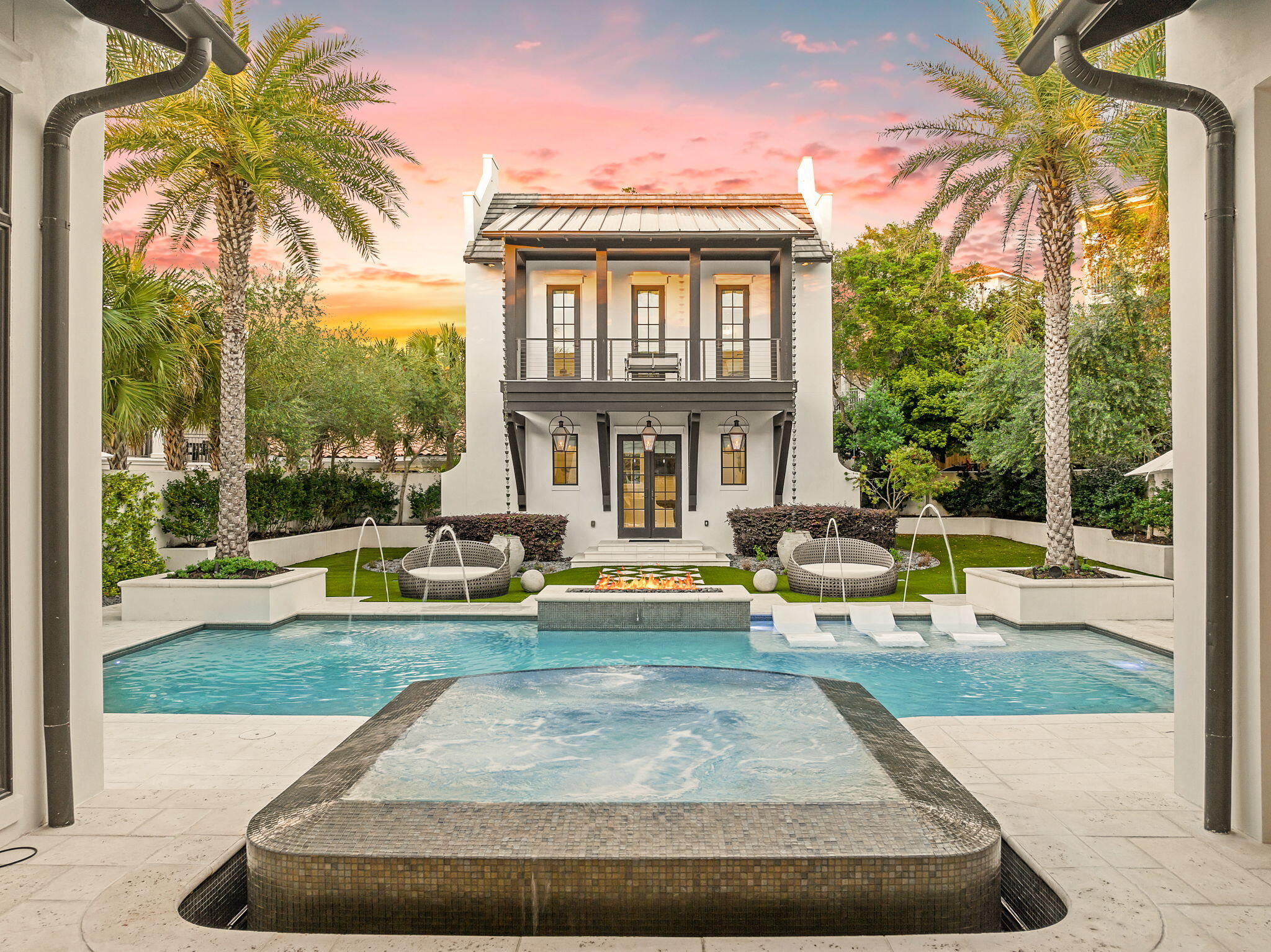 Pristine architectural design resembling the courtyard homes of Alys Beach juxtaposed an exceptional 60x300' oversized estate lot characterize 17 St. Bart's Bay as one of the most private enclaves in Destin, FL, offering notable features such as a separate carriage house with two bedrooms, additional bunk room and 3 full baths as well as a gated private deeded beach access (one of only 5 homes that share a gated, private beach boardwalk) directly south of the home. Masterfully designed as a true coastal compound by Chris Stoyles of Archiscapes with interior design by Ashley Grant Interiors, where the comfort of home meets the feel of a boutique resort highlighted by an exemplary private pool & spa with lush gardens and manicured privacy. Built with an uncommon level of intention by Magnolia Custom Homes, this residence blends substantial construction, timeless materials, and resort-style amenities into a property that feels both elevated and enduring. In a market where many homes prioritize appearance over substance, this one delivers both.

From the moment you arrive, the difference is clear. More than 150 feet of poured concrete walls, steel-supported framing, and a four-foot-wide concrete footer beneath the courtyard create a level of structural integrity rarely found along the Emerald Coast. The striking and oversized 3 car garage boasts 10' tall garage doors and custom wood awning with ample storage space and an elevated private parking court complete with Belgian cobblestone pavers all sitting over 25' above sea level. Every detail was engineered with longevity in mind, resulting in a home that feels as solid as it is refined.

Inside, the interiors strike a balance of warmth and sophistication. Soaring 20' vaulted ceilings in the living room with hand hewn cypress beams juxtaposed a pecky cypress ceiling from Amish carpenters provide an open air Caribbean layout that is both grandiose and welcoming. Reclaimed heart-of-pine flooring sourced from a historic Georgia barn adds character and depth, while shiplap, Venetian plaster, and level five drywall finishes create a clean, tailored backdrop throughout. Honed Namibian marble countertops, custom clay tile, marble, and dolomite baths continue the home's understated luxury. The living areas are indicative of a true open floorplan designed for both privacy and entertaining with a 16' long x 10' tall European nana wall that opens directly to the back patio and covered lanai. The kitchen is outfitted with a 60" Wolf gas range and griddle along with double ovens, dual Bosch dishwashers and a 48" Sub Zero refrigerator and freezer. The cabinetry is all custom built by Don Hill and his team with pecky cypress wood locally milled. The kitchen also provides a petit scullery complete with marble countertops, custom cabinetry reaching up to the 12' ceilings and ample storage and counter space. The primary suite lives like a private retreat, complete with a Victoria + Albert soaking tub and spa-like glass shower enclosure with 12' of suspended glass and floor to ceiling honed Asian statuary marble. The primary bedroom features 15' vaulted ceilings with cypress beams and pecky cypress accents as well as fully ship lapped siding and Venetian plaster gas vented fireplace. The primary suite also has a storefront glass window that is 6'x10' overlooking the serene greenery and private gardens of the courtyard with direct access through the French double doors. Custom window treatments are found throughout the home featuring Belgian linens and Lutron controls.

The floor plan was thoughtfully designed for both everyday living and entertaining at scale. A first-floor primary suite is complemented by one additional guest room on the main level, with two more full sized bedroom suites on the second level including a bunk room with 4 queen bunk beds and custom linens as well as a junior primary suite. Ceiling heights reach 12 feet downstairs and soar beyond 20 feet above, allowing natural light to pour through the living spaces. Custom furnishings, Cisco couches and bespoke millwork by Don Hill including 10' custom cypress doors complete a fully curated interior experience. Surround sound is also integrated into the home both in the main house, carriage house and resort pool area.

At the heart of the property, the courtyard becomes its own private resort. A heated pool with laminar jets cornered by double steel reinforced concrete planters that house mature Sylvester palms flank the  perimeter overflow spa and lounge areas, and rice white peacock paver decking. The outdoor lanai / covered living is an extension of the indoor living space adorned in details like the 15' vaulted ceilings, custom hanging gas lantern that provides ample ambience as well as a full outdoor summer kitchen with a lynx gas grill, large gas side burner and an outdoor refrigerator, quartz countertops as well as a separate sink and prep area. Fourteen custom gas lanterns create an unforgettable evening ambiance, while newly upgraded courtyard doors and an outdoor fireplace enhance the year-round lifestyle. Other notable features include synthetic turf for lasting durability and aesthetics in the back yard as well as a full sized children's custom playground located behind the carriage house all of which is surrounded by mature oak trees, olive groves and floral gardens that have been meticulously maintained for years. 

This home has been a strict primary residence and has never been rented, however the home is permanently grandfathered to sleep up to 24 people as a short term rental through a Bert Harris settlement with the City of Destin.

17 St. Bart's Bay is more than a home--it is a legacy property. A residence where quality construction, thoughtful design, and an unmatched lifestyle come together behind the gates of one of Destin's most private coastal enclaves. Destiny East offers gated privacy with a central clubhouse with amenities including a private gym, theatre, pools, tennis courts and playground as well as direct access to the exceptional world class shopping, dining, golf courses, marinas and recreation that Destin is famously known for.