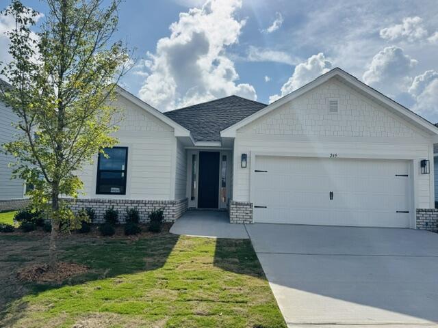 Located just a 20-minute drive to the white-sand beaches of South Walton, this Craftsman-style home blends coastal convenience with modern comfort. Offering 3 bedrooms and 2 baths, the home features Hardiboard siding with a brick skirt, 9' ceilings throughout, and elegant 10' tray ceilings in the owner's suite. Quartz countertops highlight the kitchen and baths, complemented by sleek black faucets and hardware. Durable CoreTec Pro Plus luxury vinyl plank flooring flows throughout, while the oversized owner's suite with a large walk-in closet provides a relaxing retreat. Upgraded Black Window Frames make this home a modern stunner! *Photos are of a similar home.*.  Ask about 4.99% fixed interest rate plus Move in Ready package.
