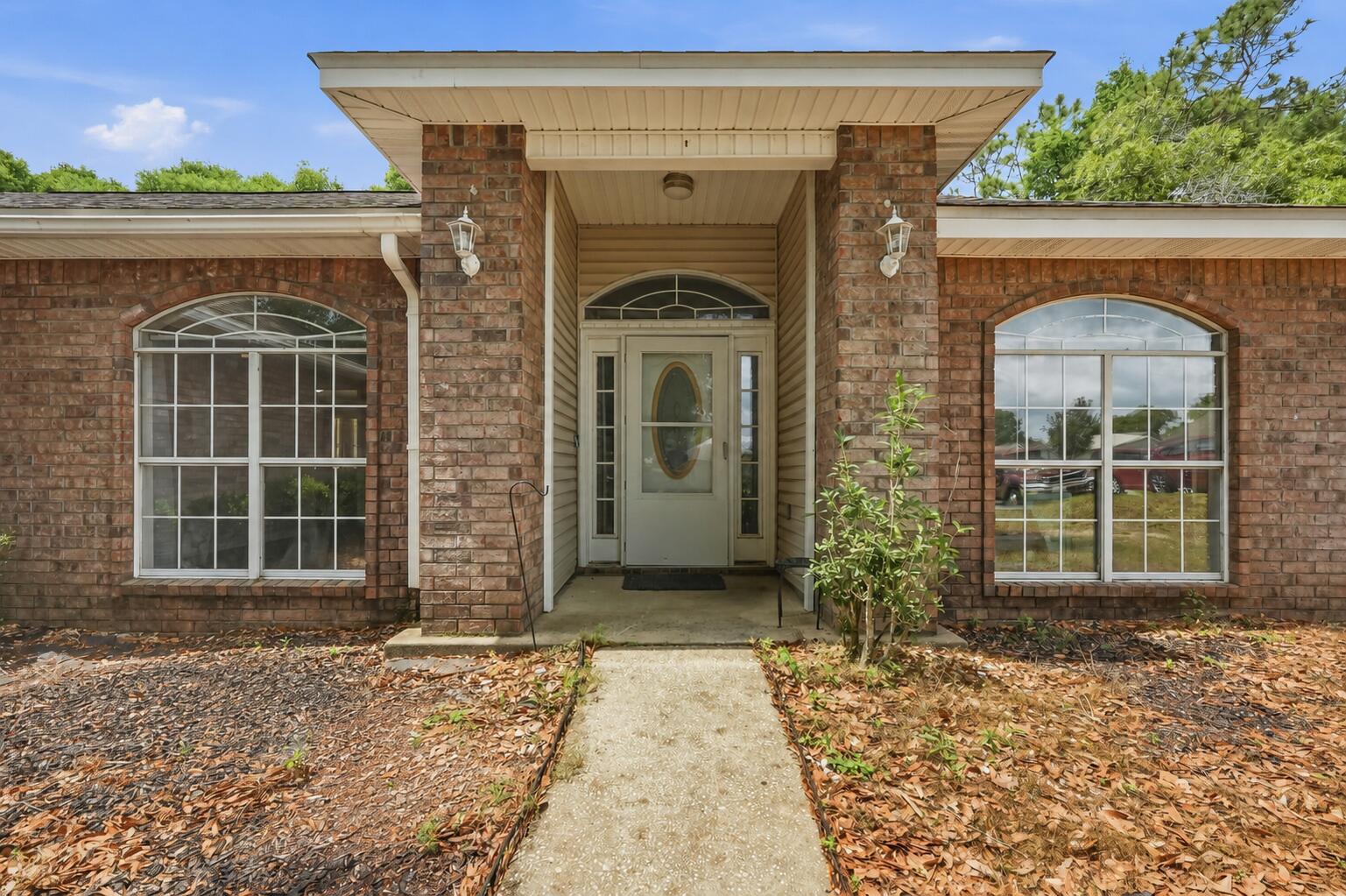 Charming and move-in ready, this beautifully maintained home offers comfort, efficiency, and a fantastic location! Featuring energy-efficient solar panels, this home helps keep utility costs down while supporting a greener lifestyle. Inside, you'll find a well-designed floor plan with tile flooring throughout the living room, dining room, and kitchen, perfect for easy maintenance and everyday living. The kitchen is a standout, with custom-built solid-wood cabinets offering abundant storage and granite countertops. Granite continues in both bathrooms, adding a cohesive and upscale touch throughout the home. Fresh interior paint gives the space a clean, updated feel. New HVAC in 2022 and new water heater in 2024. Buyer to assume the solar panel loan at closing.