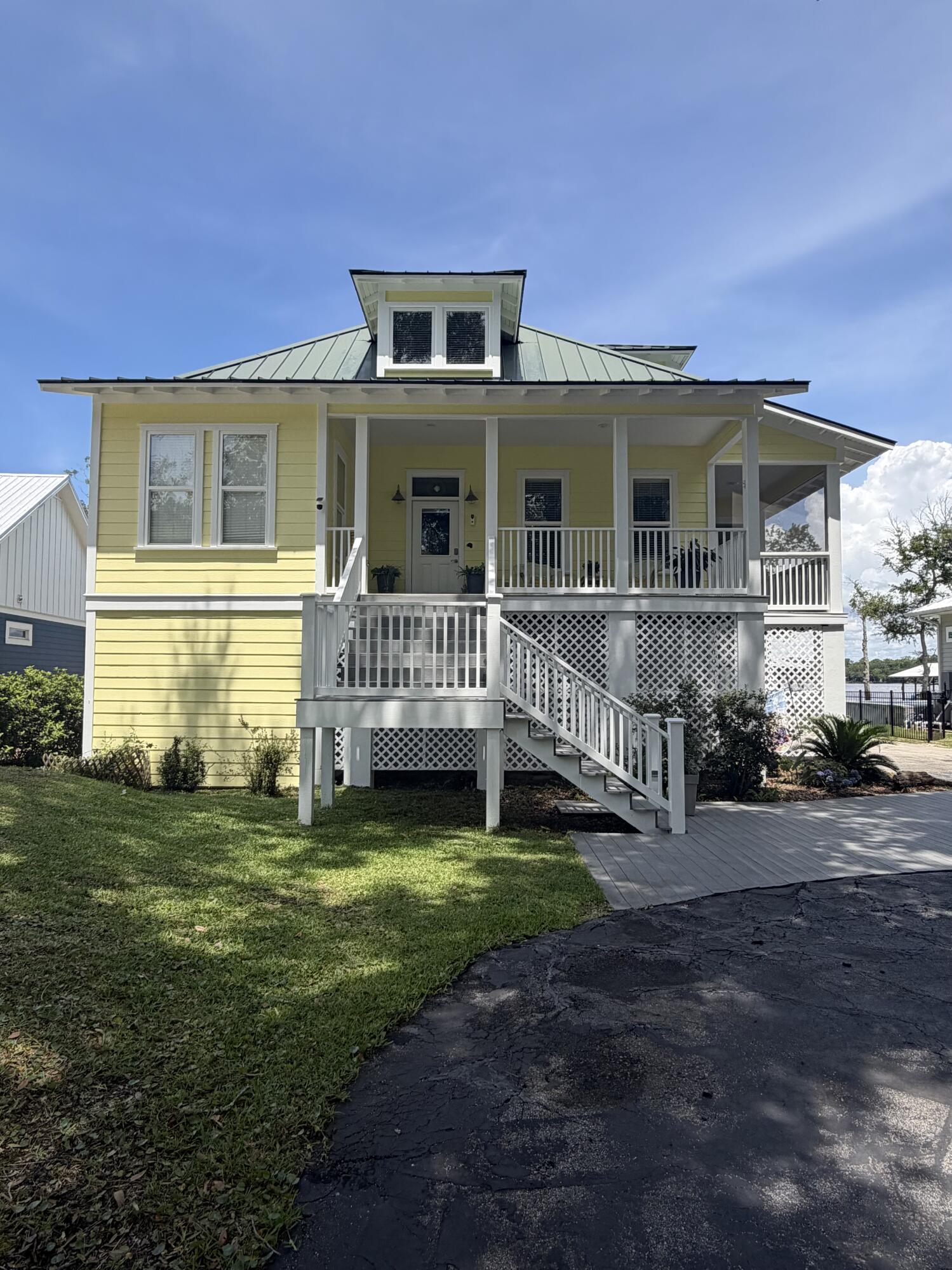 Blending relaxed elegance with unmistakable waterfront charm, this 3 BDRM 4BTH home offers the true Floridian lifestyle. The home has been completely painted on the outside in May 2026. Step outside to your private dock and take in the thriving coastal ecosystem, where each evening brings stunning, one-of-a-kind sunset views over the water. Step through the front door and into a bright, open interior where raised ceilings and expansive hallways create an inviting sense of space. To the right, the dining room extends into a screened-in porch, offering an ideal setting for effortless indoor-outdoor entertaining. To the left, a versatile drawing room or bonus space is complemented by a nearby full Guest Bath and laundry room. Continuing down the hall, you're led into a expertly curated kitchen featuring stainless steel appliances highlighted by an immaculate Verona stove imported from Italy, a beautifully designed hood, and ample countertop space for both everyday living and entertaining. The living room seamlessly connects the dining area and primary bedroom, while double doors open to a screened-in back porch-creating a natural flow for indoor-outdoor living. The Primary Bd offers access to the back porch and features a spacious walk-in closet. The Primary bath showcases artistic tile work, a double vanity, and a walk-in shower-blending modern design with a unique touch. The lower level offers a convenient half bath, additional refrigeration, a spacious living area, and a  dedicated storage room. It also connects to a garage with room for more than two vehicles and provides access to the ground level screened-in back porch-ideal for extended living and entertaining. Upstairs from the main entry, you'll find two guest bedrooms with a full bath situated between them, offering comfort and privacy for family or visitors. Whether you're seeking a full time residence or a private coastal retreat, this home offers an exceptional opportunity to experience the Florida lifestyle at its finest. 

The boat lift was used for a 20', 4700 lb boat.  

The home is built on concrete rebar pilings.  

Buyer(s) are responsible to personally verify all details for property and dimensions. Any information contained in this listing is believed to be accurate but is not guaranteed.