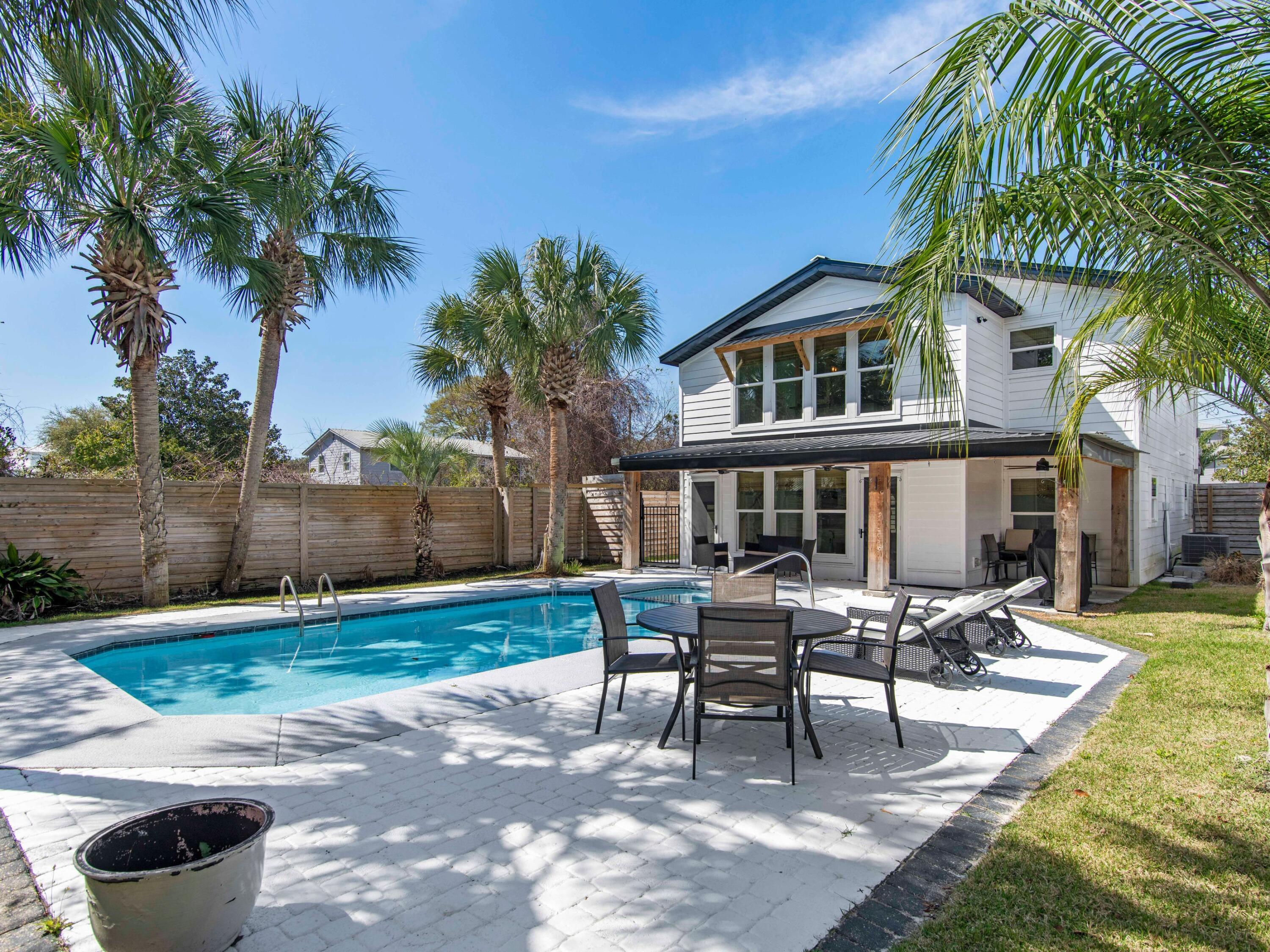 Completely reimagined and beautifully renovated, this stunning coastal retreat offers the perfect blend of luxury, comfort, and investment potential! Located in central Destin, in the much sought-after, pedestrian-friendly area of Crystal Beach! This home is just two blocks from the City of Destin's newly constructed beach access at the end of Tarpon Street and NO HOA!! Enjoy several nearby public beach access points with parking and restrooms. Build sandcastles, sit on the beach, or watch the amazing sunsets. Rent kayaks or paddle boards, take jet ski and parasailing trips, book a dolphin cruise or deep-sea fishing charter! Sit on the front porch swing and watch the traffic go by. Once inside, natural light pours through the windows, highlighting the crisp living space and beautiful coastal décor. Not only has this home been completely renovated in 2020, but the owners have also completed recent upgrades and switched the home over to a short-term rental. The home was used as a primary residence and was recently put on a short-term rental program in February 2026 and is booking fast! See complete upgrade list under the document tab. With two bedrooms, two living areas and two kitchens on each floor it provides plenty of room for everyone to spread out and have privacy. Each kitchen is fully equipped with everything you need including stainless steel appliances, all kitchen necessities, and ample counter space. The lower-level kitchen includes a wet bar with a separate beer/wine cooler and access directly to the pool deck. 
After a day swimming at the beach, enjoy the private heated pool and spa surrounded by a tropical oasis in your own backyard! The back yard is completely enclosed by a six-foot privacy fence, tall palm trees, plenty of outdoor seating, and a covered patio with a natural gas grill for barbecuing. The large front yard has plenty of parking for cars and golf carts and has room for a 32-foot boat! The side yard is fenced in for your four-legged friends and is equipped with an outdoor shower. 
Enjoy gulf-front dining at Pompano Joe's, Crab Trap or casual seafood at Fudpuckers or Camilles. Visit the large open-air Destin Commons shopping center with an AMC theater! Crystal Beach is South of Emerald Coast Parkway so you can rent a street-legal golf cart to navigate the area easily. Explore Henderson Beach State Park for scenic nature trails and pristine shorelines. Visit Marler Park for a coastal-themed playground, or Hurricane Lanes for bowling. Enjoy Big Kahuna's Water Park, play a round of golf at Seascape or drive go-karts at The Track. Bike, exercise, or simply stroll and enjoy the beautiful Gulf views along the 10-mile stretch of bike path on Scenic 98!