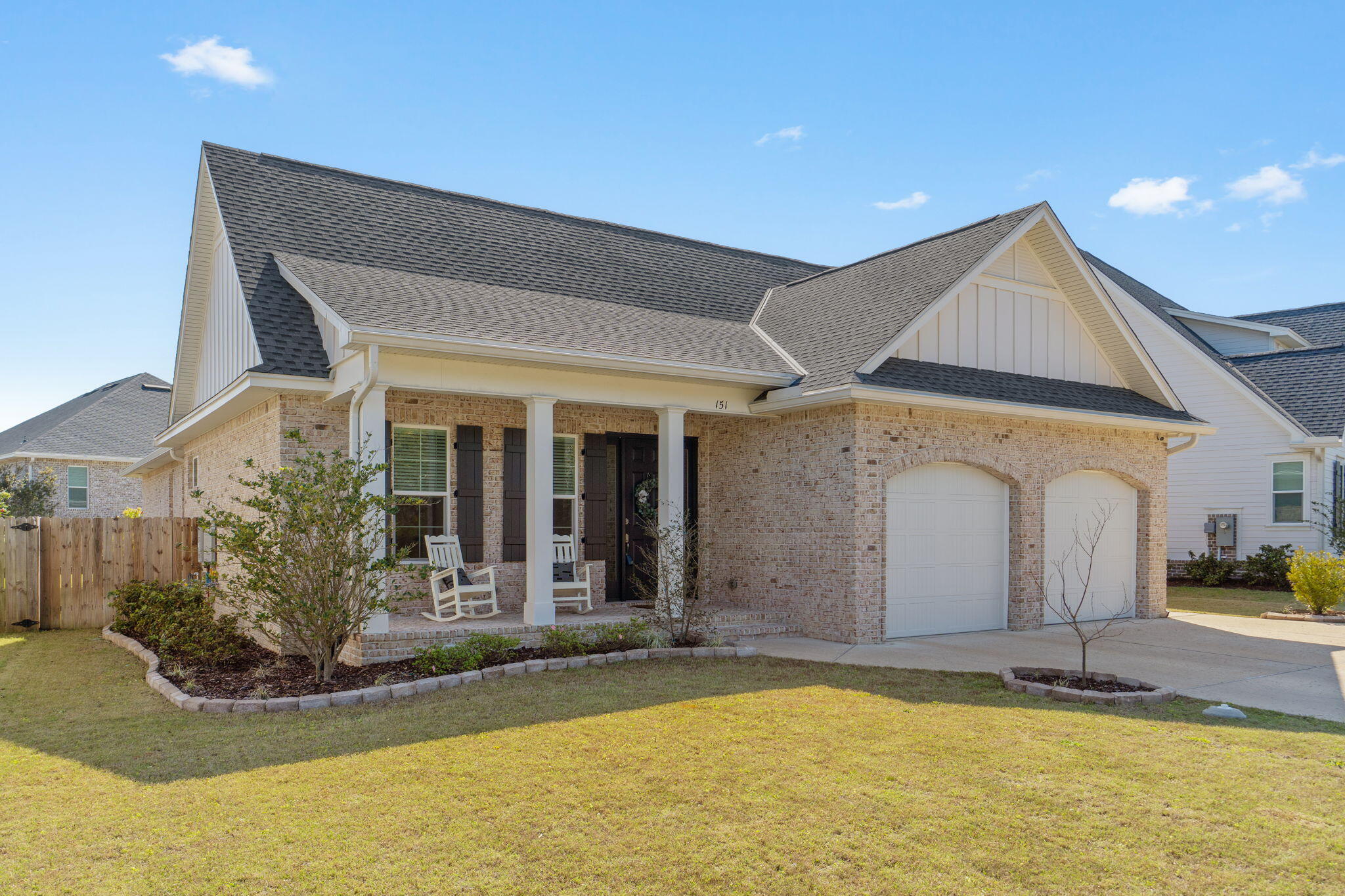 Built in 2023, this single-story home delivers the kind of thoughtful layout that just feels right from the moment you arrive. A sprawling open floor plan anchored by soaring 10-foot ceilings and three separate wings gives everyone their own space without sacrificing connection and a cohesive feel throughout.

The heart of the home opens up into a generous living, dining, and entertaining space. The kitchen is a standout, with quartz countertops, soft-close drawers, a generous island, and premium Bosch appliances including a gas range. 

Natural light pours in through clerestory windows in the kitchen and bathrooms, a lovely architectural detail. No carpet anywhere: luxury vinyl plank runs throughout the main living areas, with tile in all bathrooms and the full laundry room Frameless walk-in showers and a dedicated laundry room with sink and shelving round out the interior details with clean, timeless finishes.

The split floor plan is genuinely functional. The front of the house holds two bedrooms connected by a full bath. The opposite wing is anchored by the primary suite with spa-like bath and two closets! A fourth bedroom and third full bathroom is set just off of the kitchen. This home truly lives large, and even features a dedicated home office close to the primary. 

Out back, a screened enclosed porch opens to a flat, fully fenced yard with room to roam. The front of the home has a view of greenspace, and the covered front porch makes this one stand out.

The mechanical and utility details are equally dialed in: oversized two-car garage with EV charger, tankless water heater, impact-rated windows, irrigation system, gutters, and durable brick-and-Hardie board exterior.

Located in an established residential neighborhood zoned to Niceville High School and convenient to multiple military installations, this property is well-positioned and well-built. Must see!