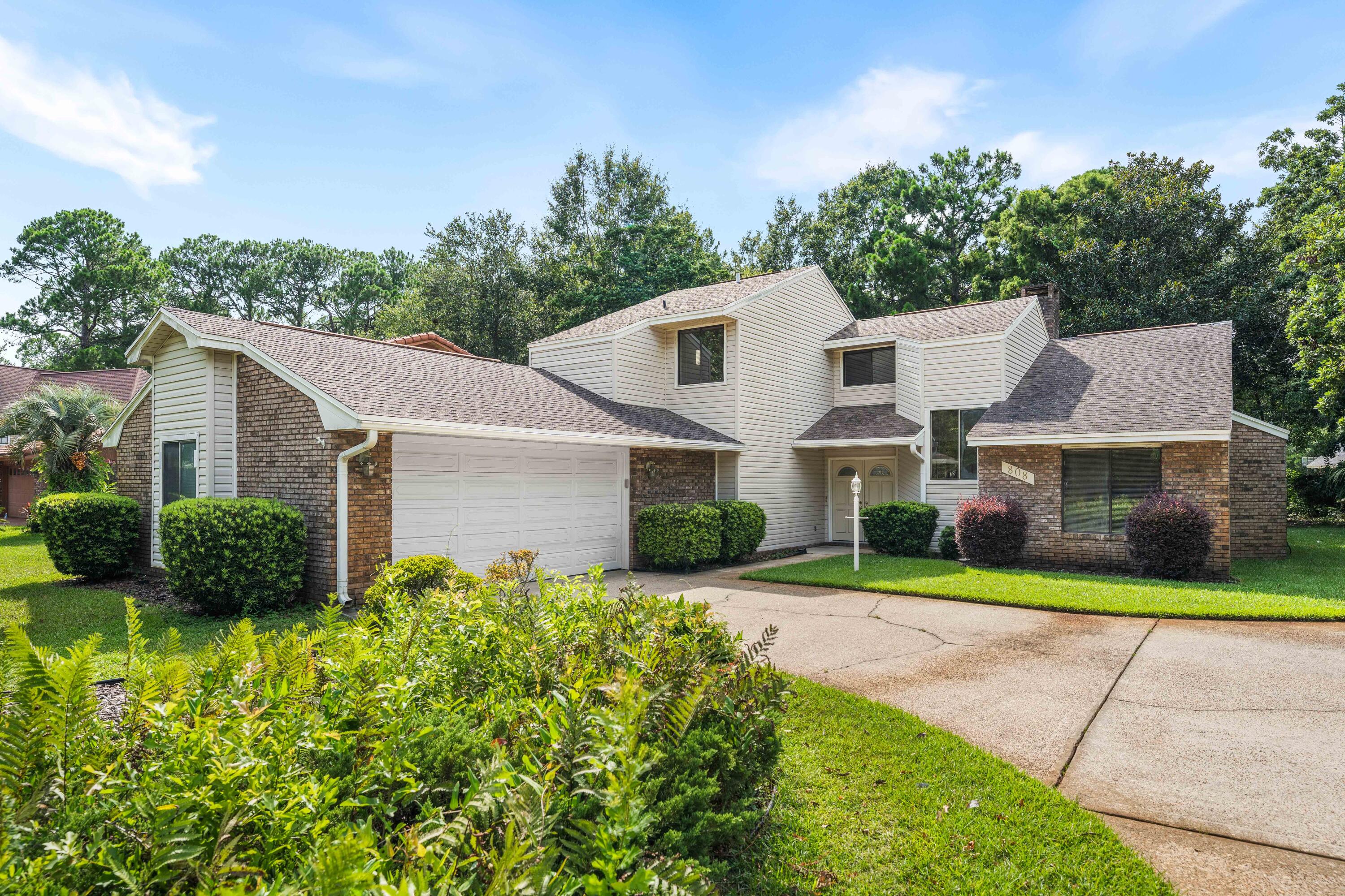 Welcome to this beautifully maintained, one-owner home in the heart of the highly sought-after Bluewater Bay golf community. Nestled on a spacious, tree-shaded lot, this inviting home offers timeless charm, abundant natural light, and room for the whole family.
The open living areas feature soaring vaulted ceilings that create a bright and airy atmosphere. The thoughtfully designed floor plan includes two guest bedrooms and a full bath on the main level, while the entire second floor is dedicated to a private primary retreat. The spacious primary suite offers a peaceful escape with its own private balcony overlooking the beautifully landscaped backyard--perfect for enjoying your morning coffee or relaxing in the evening. A versatile loft area provides additional living space that can serve as a home office, reading nook, or sitting area. Just off of the main living area, you'll find a wonderful screened and enclosed porch overlooking the private backyard. This inviting space is ideal for year-round entertaining, relaxing with a good book, or simply enjoying the peaceful setting and mature trees. Bluewater Bay is one of the area's most desirable communities, offering an exceptional lifestyle with a championship golf course, a premier tennis center, a marina, multiple community swimming pools, walking paths, parks, and more. Outdoor enthusiasts will love being just minutes from Rocky Bayou State Park, where hiking, kayaking, and nature trails await. The sugar-white beaches and emerald waters of Destin are only a short drive away, along with outstanding dining, shopping, and entertainment. This lovingly cared-for home is ready to welcome its next owners and offers the perfect combination of comfort, location, and the unmatched Bluewater Bay lifestyle. Make your appointment today! Buyers and Buyer's Agent to verify all information and measurements.