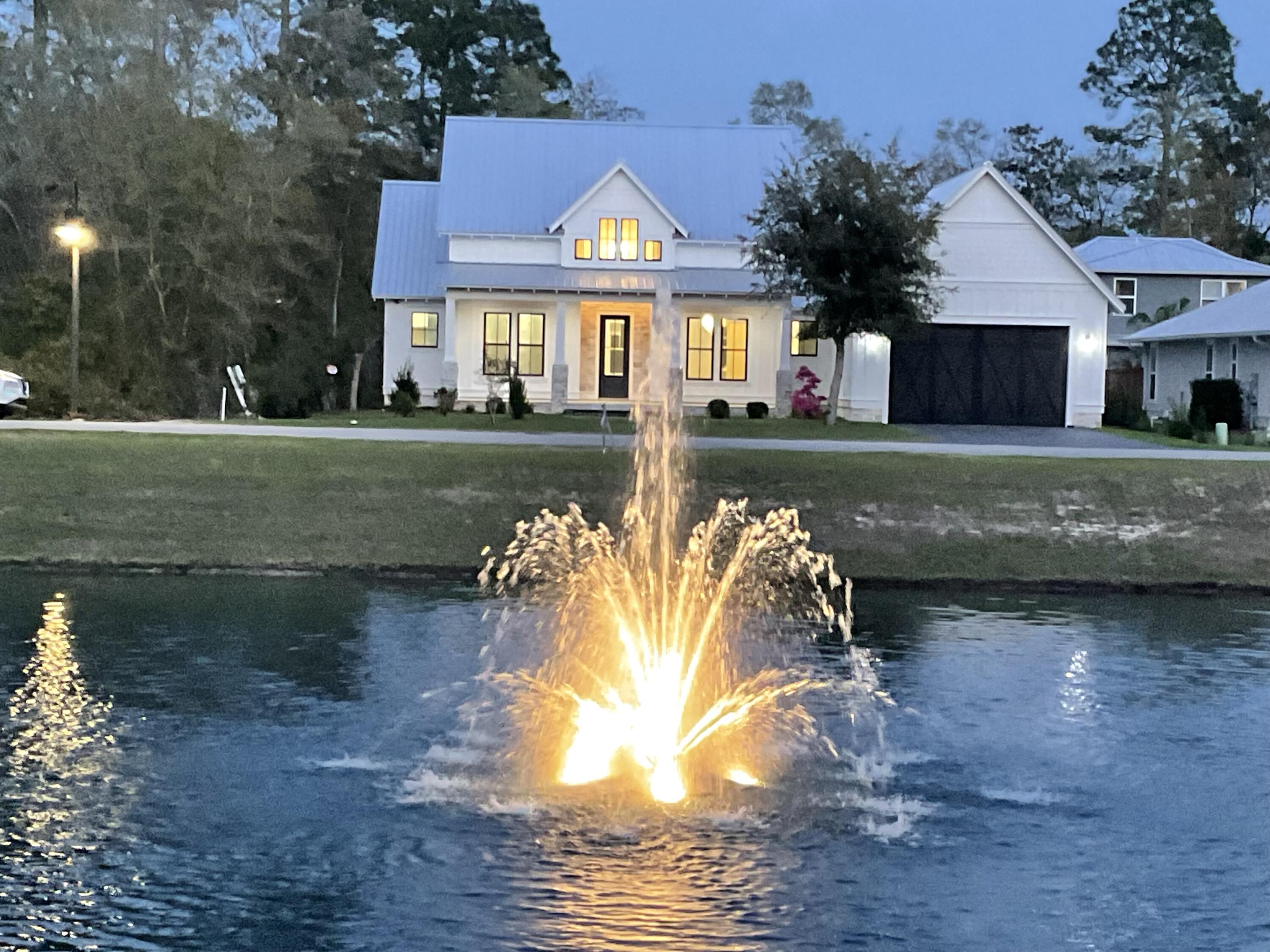 *** New construction tucked away on one of the larger lots in Bear Creek Cottages, just 10 minutes from the beautiful beaches, parks, restaurants, and golf courses of South Walton and 30A.
This stunning 3-bedroom, 3.5-bath home features an open floor plan with 12-foot ceilings and thoughtful, high-end finishes throughout. Highlights include keyless entry,  impact-resistant windows and doors, a durable metal roof, an oversized garage with additional storage, hardwood floors, vaulted ceilings, a cozy fireplace, and the master bath features luxurious soaker tub.
The chef's kitchen is designed for both everyday living and entertaining, complete with KitchenAid appliances, a gas cook top and a convection wall oven.
 The home offers two spacious porches wired for .... ceiling fans The front porch overlooks a charming fountain and manicured lawn, while the rear porch is equipped to mount a 80 inches TV--ideal for outdoor gatherings.
This impressive home is perfect for hosting family and friends while enjoying life in a highly sought-after planned community. Amenities include pickleball, tennis and basketball courts, a children's play area, fitness center, and an Olympic-style pool.
Don't miss this opportunity--BUY NOW ! Additional homes are available in Phase 2, offering options for everyone in this desirable community.