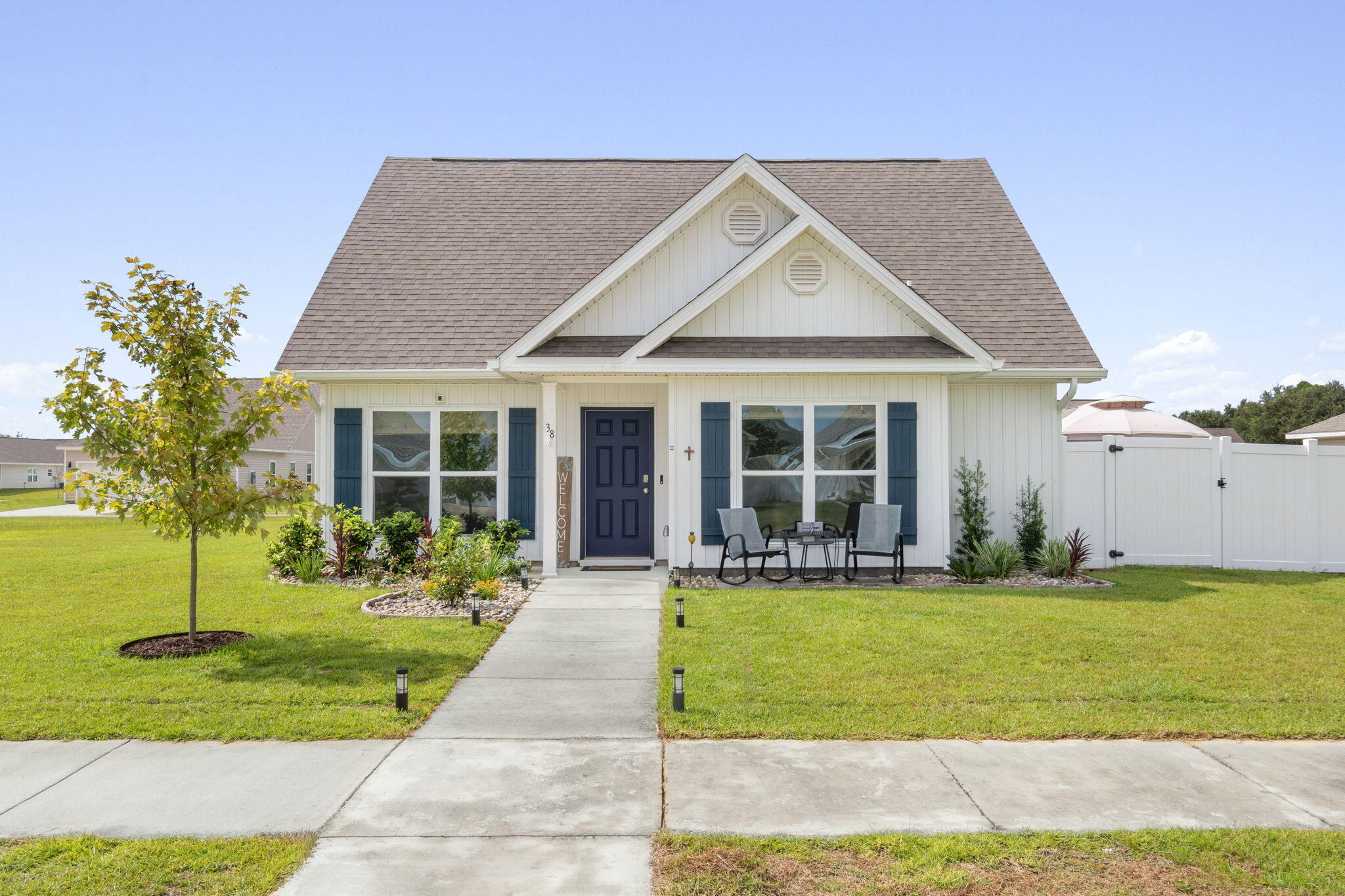With over $20,000 worth of upgrades, this gently lived-in-2 yr old home offers the rare blend of contemporary design, functional comfort, and an abundance of outdoor living space! A standout feature is the fully fenced large, private side yard (easily accessed from the living area) adorned with beautiful brick pavers, lush landscaping, irrigation and a soft-top gazebo that offers shade for outdoor dining, morning coffee or family gatherings.  The LVP flooring seamlessly connects the living areas, while plush carpeting lends comfort to each of the 3 bedrooms.  The split floorplan provides privacy for the primary bedroom and an open flow between the kitchen, dining and living spaces - ideal for entertaining.
