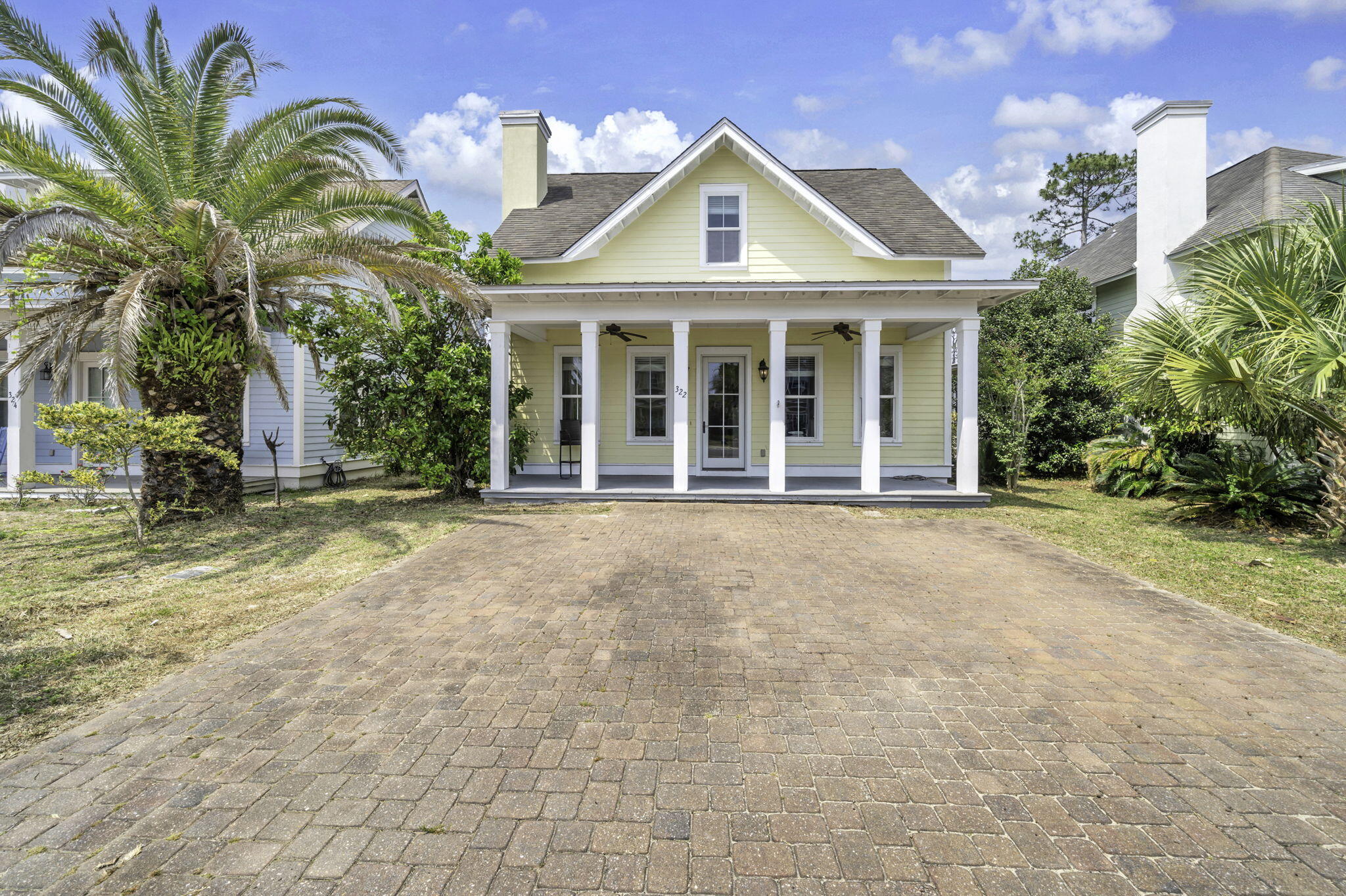 Spacious coastal living just minutes from the Gulf of Mexico. This 4-bedroom home in Harrison's Walk delivers style, space, and an unbeatable location.

Welcome to this beautifully updated 4-bedroom, 3.5-bath home in the sought-after community of Harrison's Walk, ideally located near the beach. Offering generous square footage at an exceptional value, this home combines comfort, style, and convenience in a peaceful coastal setting. From the moment you arrive, you'll notice the inviting curb appeal with a covered front porch and brick paver driveway. Inside, the home features fresh interior paint, brand-new carpeting, and durable tile flooring throughout the main living areas. Elevated ceilings and abundant natural light create a bright and airy atmosphere, while details like crown molding and classic wainscoting add a touch of coastal charm.

The thoughtfully designed open layout is perfect for both everyday living and entertaining. The kitchen is well-appointed with rich wood cabinetry, expansive granite countertops, and a breakfast bar accented by pendant lighting. It flows seamlessly into both a formal dining space and an additional casual dining area, offering plenty of room for gatherings.

The primary suite is conveniently located on the first floor and provides a spacious retreat with a private ensuite bath featuring dual vanities, granite surfaces, and a shower/tub combination. Upstairs, you'll find three additional bedrooms, including one with its own private bath, while the remaining bedrooms share a well-designed hall bath. A versatile loft area at the top of the stairs, complete with hardwood flooring, offers the perfect space for a second living area, office, or media room.

Residents of Harrison's Walk enjoy access to a community pool and a quiet, residential atmosphere just moments from shopping, dining, and beach access. Short-term rentals are not permitted, making this an excellent option for a primary residence or long-term investment property, with a minimum six-month rental policy in place.