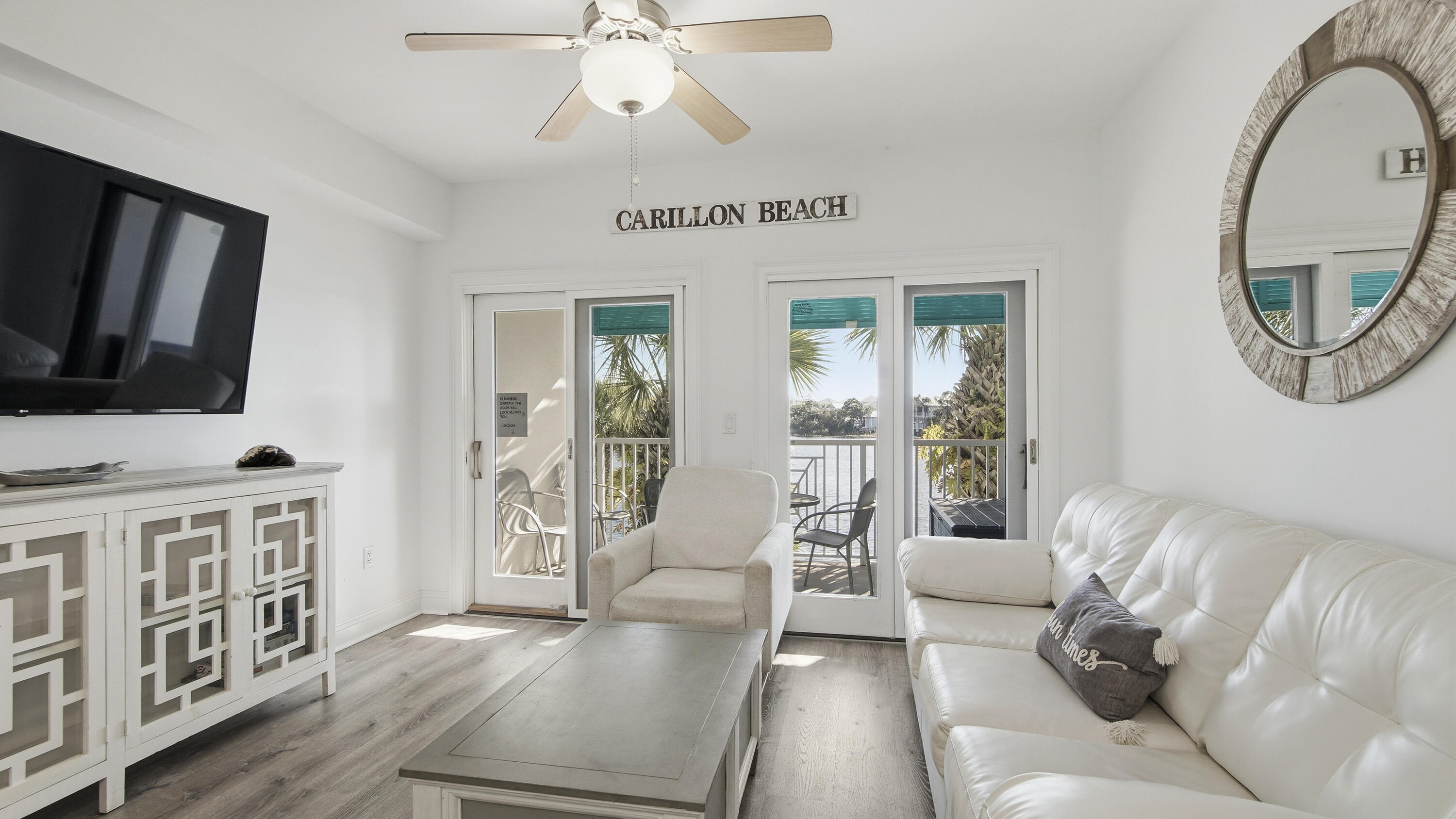 RENOVATED. TURN-KEY. INCOME-READY.
This is the kind of condo buyers wait for--and rarely catch.  Perched on the second floor of Carillon Beach Inn, this fully upgraded unit delivers what most 'updated' listings promise but don't: a true, start-fresh renovation with a clean coastal feel that instantly puts you in vacation mode.  The kitchen? Done right. Granite countertops, a generous breakfast bar for slow mornings or evening cocktails, stainless steel appliances, and updated cabinetry that actually feels current--not 'recently refreshed.'
Luxury vinyl flooring runs throughout, paired with curated coastal furnishings that make this unit not just move-in ready--but rental ready on day one.
And then there's the view.
Step onto your private balcony and you're looking straight out over Lake