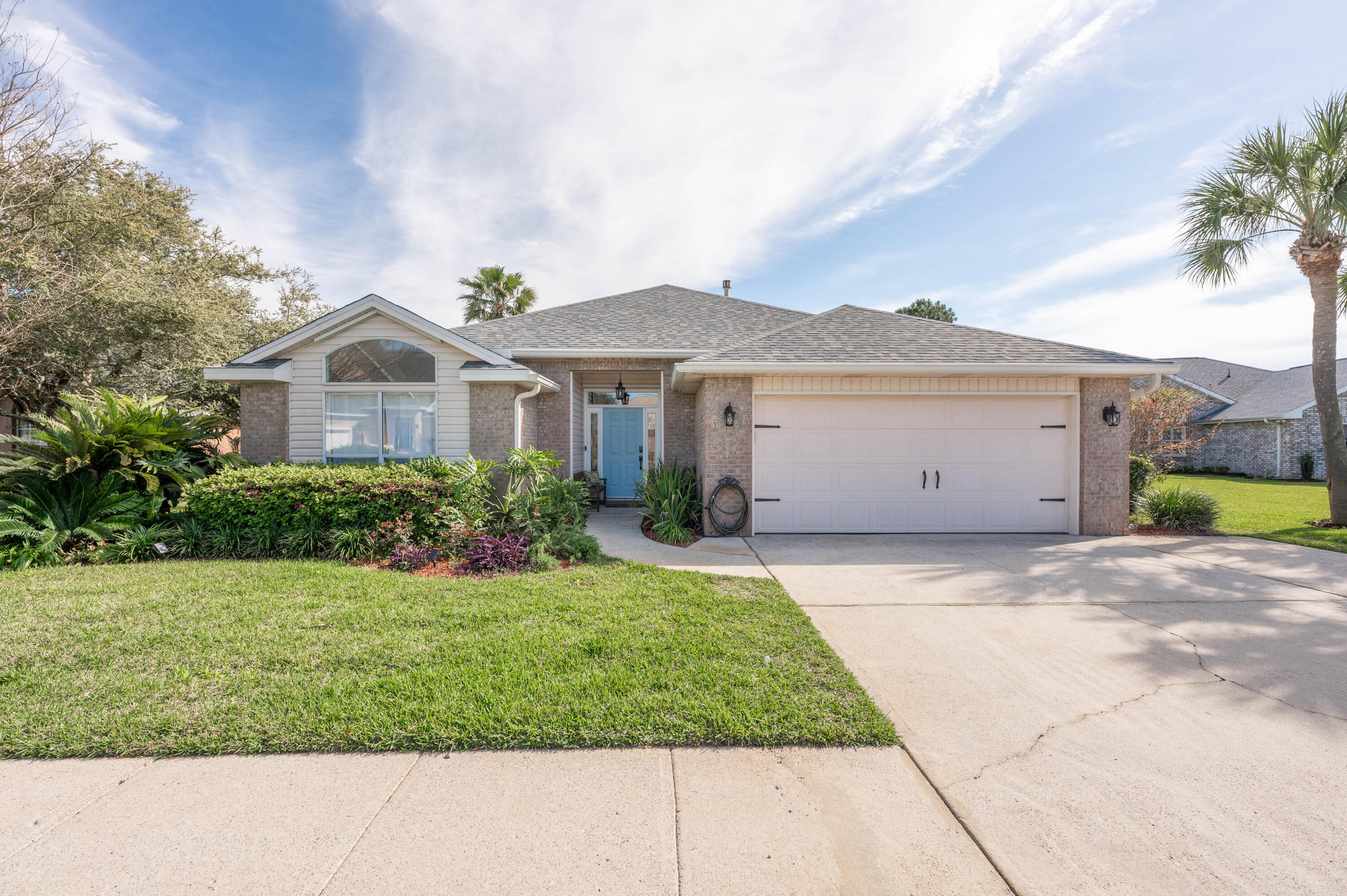 Imagine living just a short stroll away from the beach with a private community entrance. Located in the sought after Avalon Beach Estates, this home is all about the easy going coastal lifestyle. The house features a beautiful screened porch, a floor-to-ceiling screened porch, it's the perfect spot to catch a Gulf breeze and fills the entire living area with natural light.
The layout feels open and inviting, featuring a kitchen island made for gathering and a cozy fireplace for those rare chilly Florida nights.  With three bedrooms in a split plan, there's plenty of privacy for everyone. Outside, the fenced backyard is a quiet retreat, and the community offers everything from a heated pool to pickleball. Whether you're looking for a full-time residence, STR or a weekend getaway.