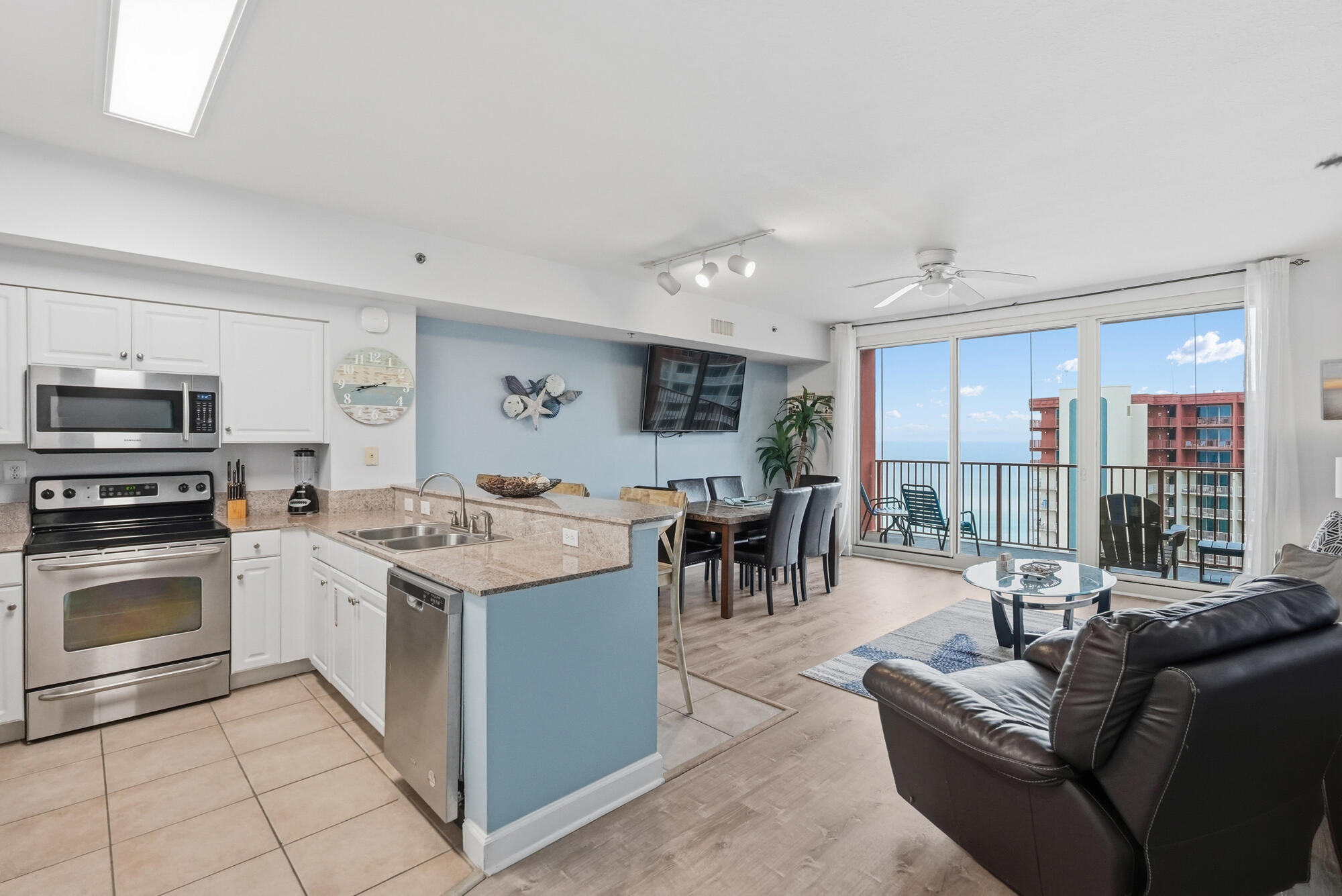 Projected to generate $40K+ in 2026 with current management and new 2BR marketing (barn door bunk area). Previously produced $33,200 gross (Jan-Oct 2025) despite being offline Nov-Mar for stucco work. Major updates include new Carrier heat pump ($6,300), and water heater; updated electrical panel, LifeProof LVP flooring, new appliances (fridge, dishwasher, washer/dryer), furniture, and fresh paint. Deeded parking space adds rare convenience and rental appeal. Low-maintenance, rental-ready, and ideal as a short-term rental, second home, or beach getaway!