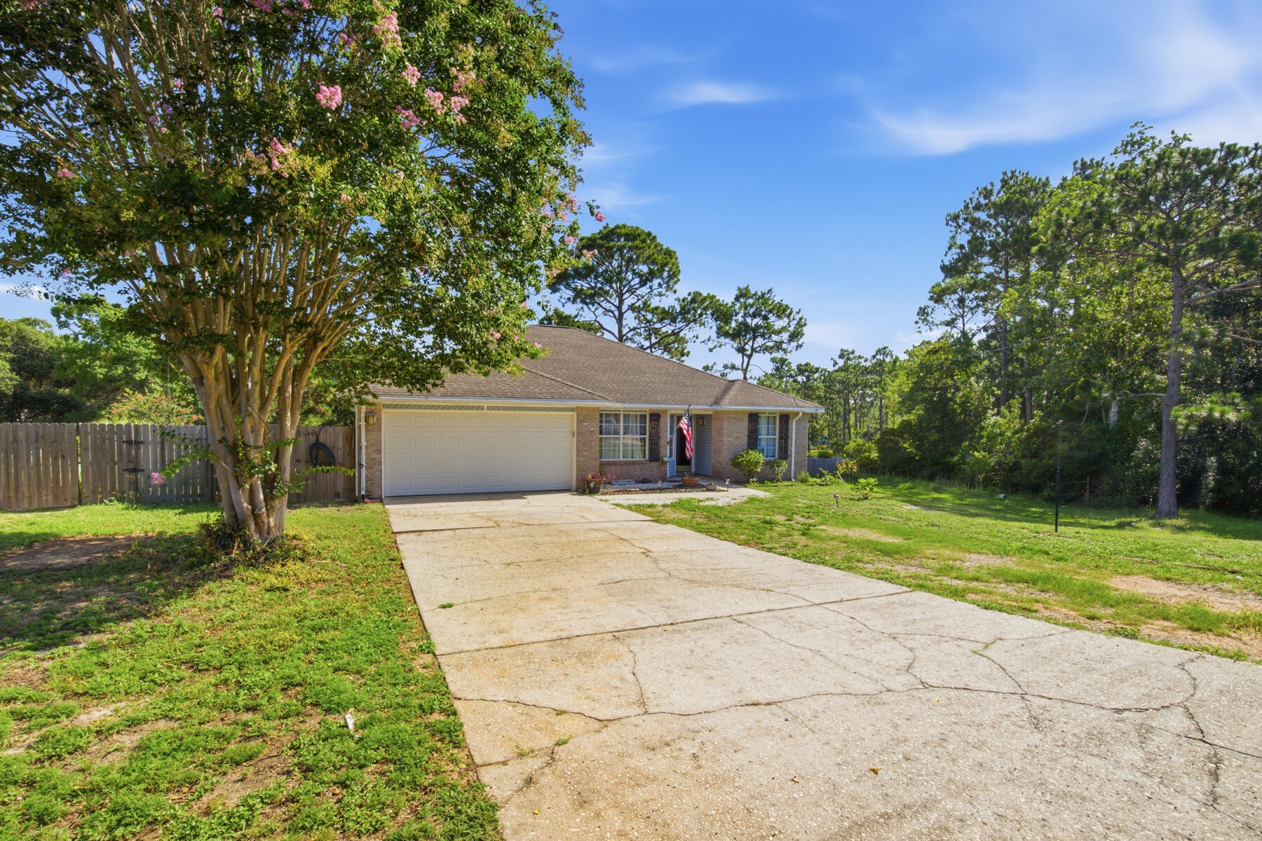 Welcome to your own private retreat in the heart of Navarre! Nestled on an expansive 2.39-acre cul-de-sac lot, this beautiful 4-bedroom, 2-bath home offers the perfect combination of privacy, space, and modern comfort--all just minutes from shopping, schools, Hurlburt Field, and the world-famous white sand beaches of the Emerald Coast.  Step inside to discover an inviting open-concept floor plan featuring soaring vaulted ceilings that create a bright and spacious atmosphere. The heart of the home is the well-appointed kitchen, complete with a large center island, abundant cabinetry, and plenty of workspace, making it ideal for entertaining family and friends.
The spacious living and dining areas flow seamlessly together, while the generous bedrooms provide comfort and flexibility for family, guests, or a home office.
Step outside and enjoy the oversized rear deck, the perfect place to relax with your morning coffee, host weekend barbecues, or simply take in the peaceful surroundings of your private acreage. With 2.39 acres, there's plenty of room for gardening, recreation, future additions, or simply enjoying the extra space and privacy that is becoming increasingly hard to find.
Priced at $369,000, this exceptional property offers a rare opportunity to own acreage in Navarre without sacrificing convenience. The HVAC system was replaced in 2024 and the roof in 2016.  Don't miss your chance to make this beautiful property your new home--schedule your private showing today!