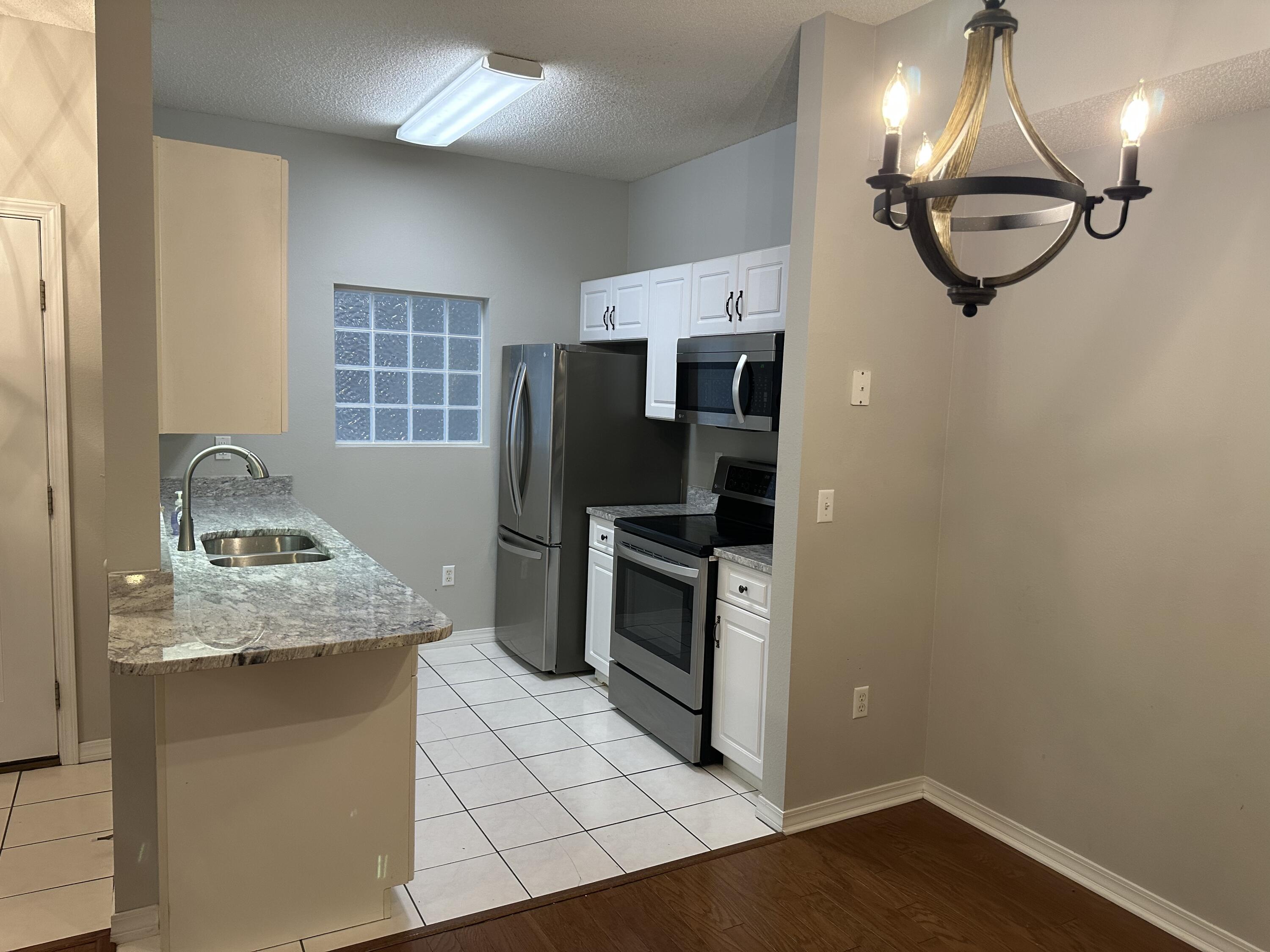Immediate Occupancy! Second floor 3 BEDROOM, 2 BATH unit with vaulted ceilings and hardwood floors, and lots of upgrades to include new countertops and flooring! Beautiful balcony overlooks the swimming pool and Gazebo. Text Tiffani 850-797-0681 For more information and viewing. Small pets allowed with owner approval. Non smoking unit.