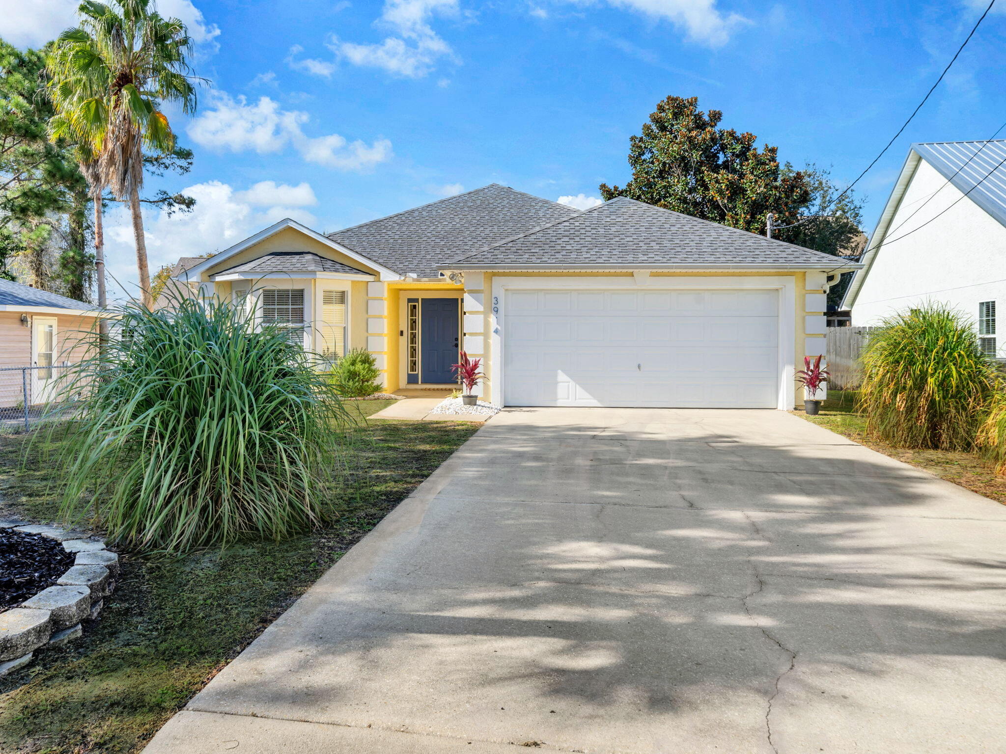 This is THE ONE you've been waiting for! The perfect beach home for an unbeatable price! What a find! This recently updated property boasts a uniquely large amount of space. With 1451 square feet, this coastal charmer has 3 bedrooms and 2 bathrooms in a split floor plan design, all on one level. Spacious indoor and outdoor living areas provide the absolute perfect accommodations for you, your family and your guests. You will love the tasteful new decor, new furnishings, and fresh paint inside and out. Mostly you will enjoy that it is all walking distance to the world's most beautiful beaches! Features include an extra large master suite with bay window, open concept living areas with vaulted ceiling, wood burning fireplace with chimney, large laundry room with full size washer and dryer, upgraded LVP flooring, owners closet, security cameras, smart thermostat, as well as new HVAC system, 2019 roof, new LG appliances, and a newly designed outdoor patio area that creates a private backyard oasis, providing ambiance with plenty of seating, space to eat, entertain, grill and relax. Next to the covered pergola, the Adirondack chairs surround the fire pit, and hammocks hang waiting in the trees. All topped off with a sprinkle of lights overhead, perfect for intimate evenings or early morning coffees. This is truly the perfect property for a forever home, vacation getaway, or investment opportunity. In addition, septic is in the front yard, so installing a pool in the back yard is an option. As an investment property, this home is rated as a ''Guest favorite'' on Airbnb based on ratings, reviews, and reliability, producing $37K in rental income in 2024, its first year as a vacation rental, and already at $20K for 2026. This seaside dream is 1/2 mile from beach access #14,#15, and #16, a 5 minute walk to Richard Selzer Park, and a short walk or golf cart ride to some of the very best restaurants and entertainment spots that PCB has to offer. Also nearby are marinas, public boat ramps, St. Andrews State Park, and more! Experience the ultimate in coastal living. This beautifully updated home is ready to enjoy! Truly turnkey, all this house is missing is you! Call today for your private viewing. *All information is approximate and should be verified by buyer if important.