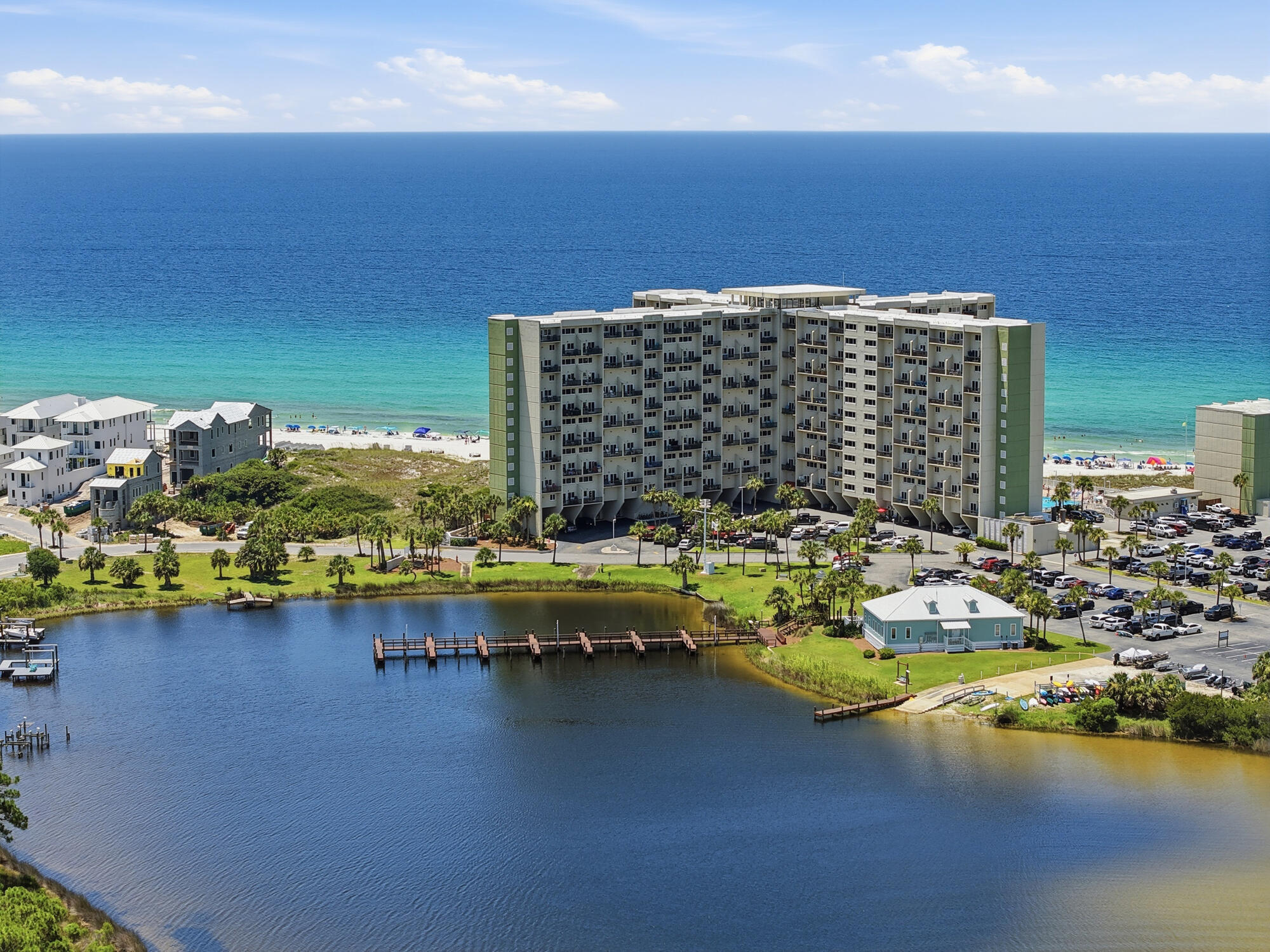 One of the few opportunities currently available at Pinnacle Port with an EXCEPTIONAL rental history, this beautifully maintained condo offers an impressive calendar of bookings (almost every day turn around!), outstanding 5-star guest reviews, and a loyal base of returning visitors year after year. Those are most valuable trades in vacation rental business that is already established for this property! Professionally staged(yes, owner paid for it!), fully furnished, and truly turnkey, it's ready to continue its success as a high-performing vacation rental or become your own private coastal retreat. Finally, a waterfront property where you don't have to choose between the Gulf and the lake. Here, you can enjoy breathtaking Gulf sunsets from your living room while overlooking the peaceful waters of Lake Powell from the dining area and primary suite - a combination so rare that it truly sets this condo apart. Inside, the thoughtfully updated interior features an open-concept kitchen with granite countertops, a breakfast bar, and spacious living areas designed for entertaining. Upstairs, the loft has been transformed into a private retreat with a custom stone and tile shower and a sliding barn door, creating a flexible space for owners and guests. Unit perfectly located in the center of the building at perfect height, and close to the elevator! Pinnacle Port is one of Panama City Beach's most unique waterfront communities, tucked behind the gates of Carillon Beach on 25 acres where the Gulf of America meets Lake Powell.