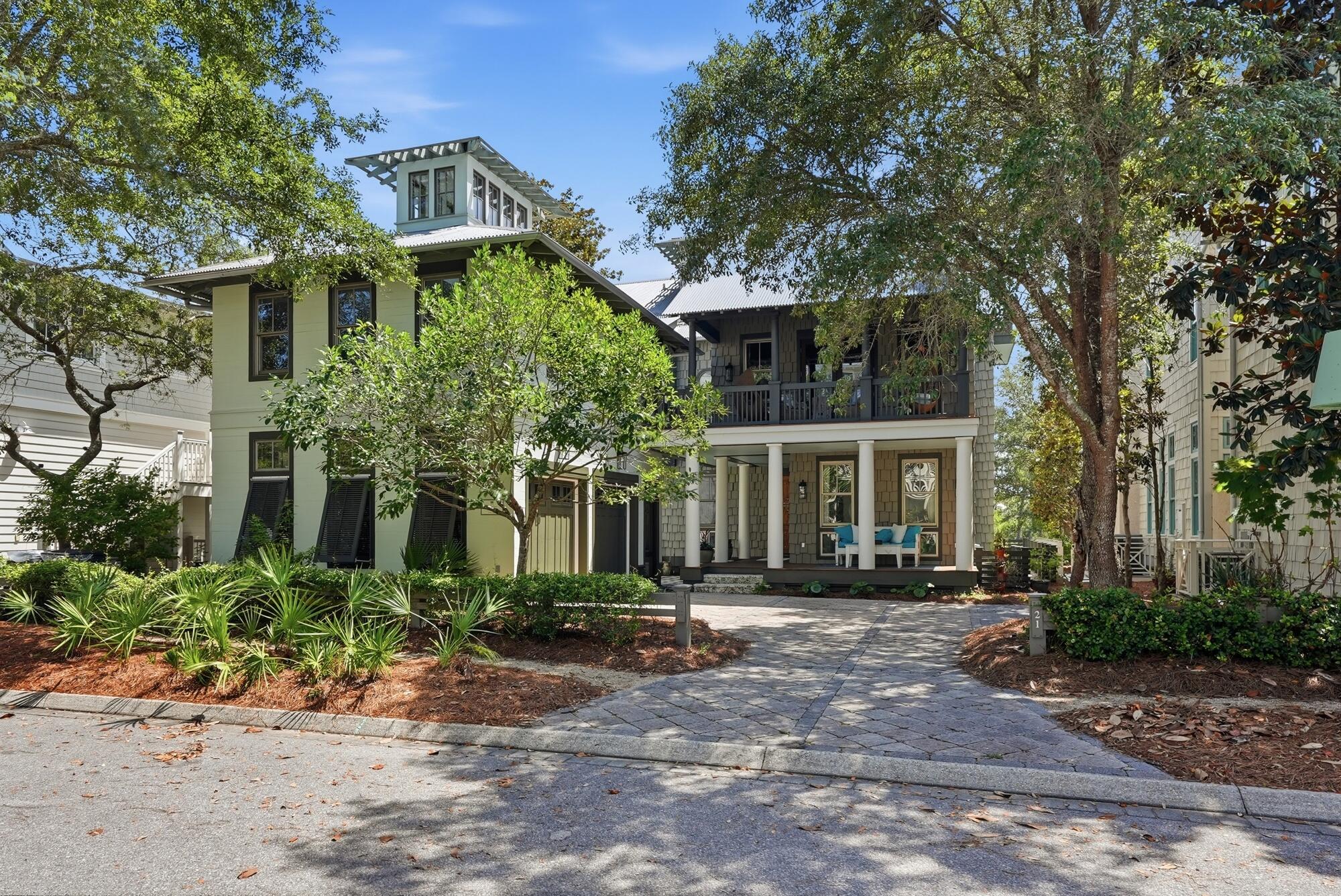 21 Blackwater Street presents a rare opportunity to own one of 30A's most compelling waterfront residences--offered at an extraordinary value, approximately $800,000 below appraised value. Spanning 4,007 square feet across three thoughtfully designed levels, this four-bedroom, four-and-a-half-bathroom home blends refined architecture, sophisticated interiors, and an unparalleled connection to the natural beauty that defines the Emerald Coast.

From the moment you enter, rich hardwood flooring, a striking glass-railed staircase, and expansive lake views establish a sense of understated elegance. The main living area is anchored by custom built-ins and framed by windows that capture the ever-changing scenery of Western Lake. Designed for both entertaining and everyday living, the chef's kitchen features an oversized island, Viking range, built-in coffee system, and generous gathering spaces that flow seamlessly to multiple porches overlooking the water.

The second-floor primary suite offers a private retreat with its own balcony, dual walk-in closets complete with custom cabinetry, a dedicated makeup vanity, and a spa-inspired bath featuring a soaking tub and separate shower room. Additional accommodations include spacious guest suites, a custom bunk room, a media room with built-ins, and a fitness room with wet bar, creating exceptional flexibility for hosting family and friends. Outdoor living is equally impressive. An intimate courtyard centered around a fireplace and fountain invites relaxed evenings beneath the stars, while oversized screened porches provide front-row views of one of South Walton's most treasured coastal dune lakes.

A two-car garage, abundant storage, and carefully curated design details throughout enhance both comfort and functionality. Just moments from WaterColor's celebrated amenities--including resort-style pools, nature trails, parks, and access to the Gulf--and within easy walking, biking, or golf cart distance of Seaside, acclaimed dining, boutique shopping, and the sugar-white beaches of 30A, this residence embodies the effortless luxury and coastal lifestyle for which the community is renowned. Short-term rentals are permitted, further enhancing the property's versatility and investment potential.
