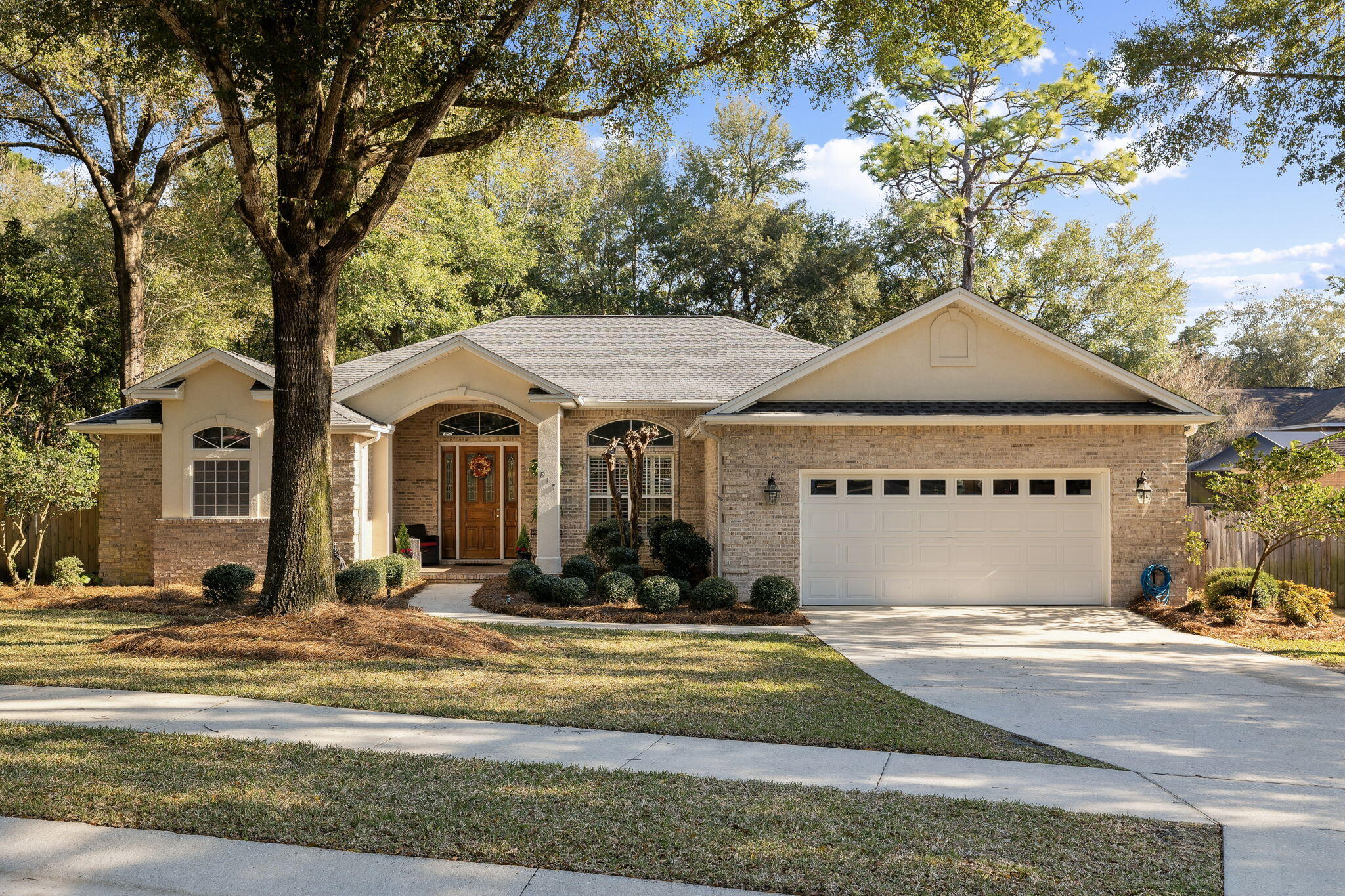 Swift Creek is the definitive premier neighborhood community in the twin-cities region. Adorned with an exceptional location, mature landscaping, and top tier amenities - Swift Creek is an ideal place to establish your new residence in Northwest Florida. As you make your way to 817 Coldwater Creek Circle, you will find yourself insulated from the everyday hustle and bustle of life. Approaching the property you are welcomed into a serene setting presenting outstanding curb appeal as well as timeless architectural charm. A thoughtfully designed layout balances openness and warmth, making you feel right at home from the second you arrive.  The front door and arched transom of the entry-way are simply a sight to see. Offering 4 bedrooms and 3 baths, this residence boasts enough room for the entire family as well as your guests. There are multiple living and dining areas giving you space for peace and practicality. Porcelain tiling has been carried throughout the entire home.  11' ceilings, crown molding, and deep base boards complete the picture of elegance.  The kitchen flows seamlessly into the family room creating an atmosphere where forever memories are sure to be made. Notable features include stainless steel appliances, Corian countertops, and a spacious breakfast bar.  Natural light fills the home providing the distinctive Florida feel sought by many. Bedrooms are positioned in a way that promotes privacy and tranquility.  The primary bedroom is a sanctuary for the owners accompanied by a spacious ensuite bathroom featuring double vanities, a garden tub, walk-in shower, and his and her walk-in closets.  There is a section of the home equipped with a private entrance accompanied by its own bed and bath.  The great room of the home features plenty of space as well as a gas burning fireplace perfect for the seasonal weather we are fortunate to enjoy.  Perhaps one of the most enticing features of the home is a climate controlled retreat at the back of the property just above 300 square feet.  The bookshelves and bricks that permeate the space present a character and setting that must be seen in person.  The 2 car garage has built in shelving for your tools, fishing rods, and more.  It also includes a secondary refrigerator.  Out back you will find a gazebo equipped with power and a flat screen TV, perfect for outdoor living and entertaining.  From the moment you arrive it is evident the home has been loved and cared for and is now poised for its next owners to possess.  Located close to Eglin Air-Force base and a top ranked "A" rated school system.  Schedule your showing today!
