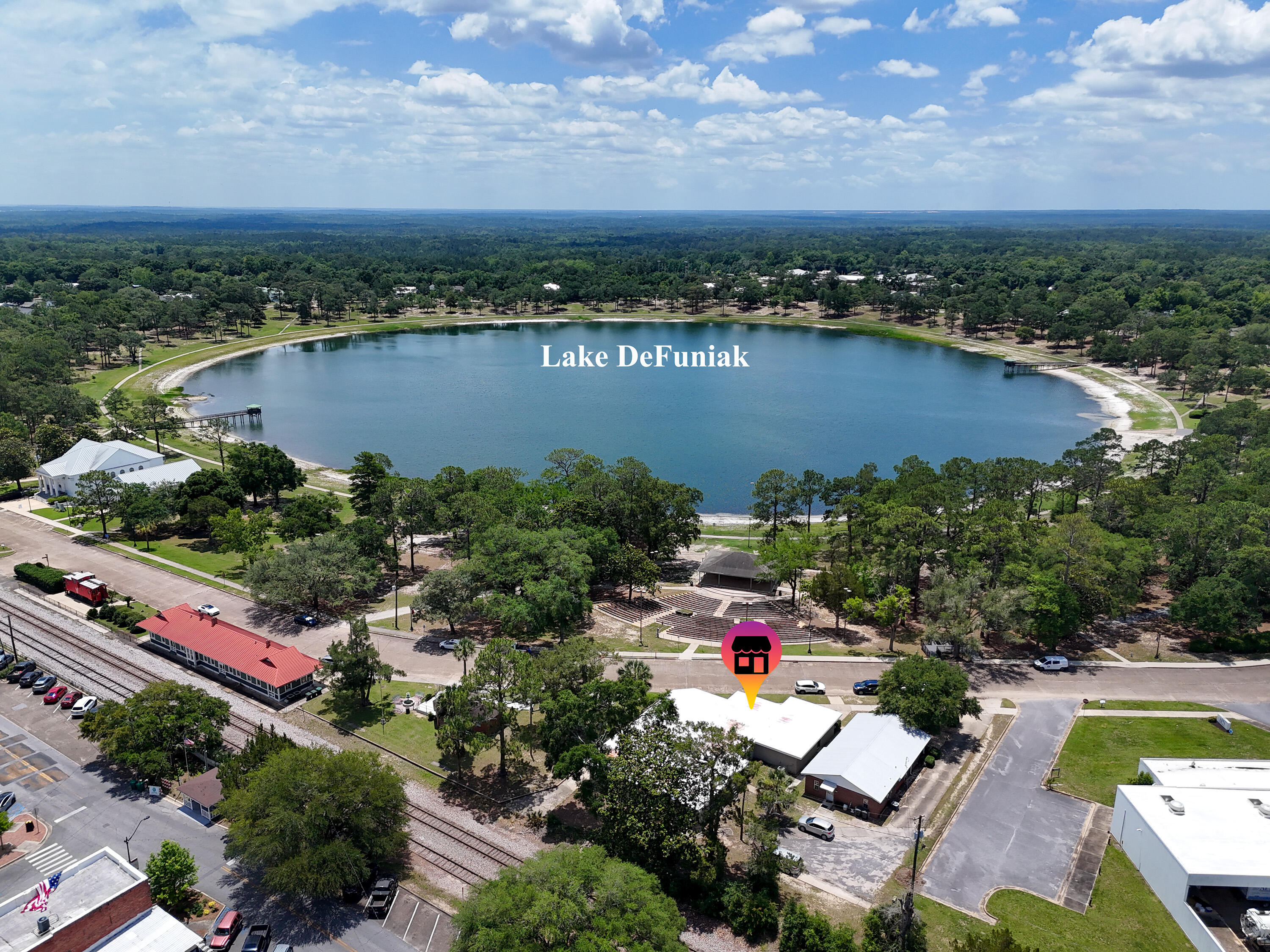 Rare downtown commercial lease in DeFuniak Springs, this spacious corner unit offers approximately 1,589SF with views of Lake DeFuniak. The well-planned layout includes a large reception area, four generously sized offices, two bathrooms, and a dedicated breakroom or kitchen area, making it an excellent fit for medical, physical therapy, counseling, aesthetics, wellness services, or professional care practices. The space is designed for smooth flow and functionality, allowing most users to operate with minimal modification. Natural light and a prominent corner presence enhance visibility in a vibrant downtown setting across from the lake and amphitheater. Exterior updates are underway, with refreshed photos coming soon. Tenant is responsible for utilities, internet and phone.