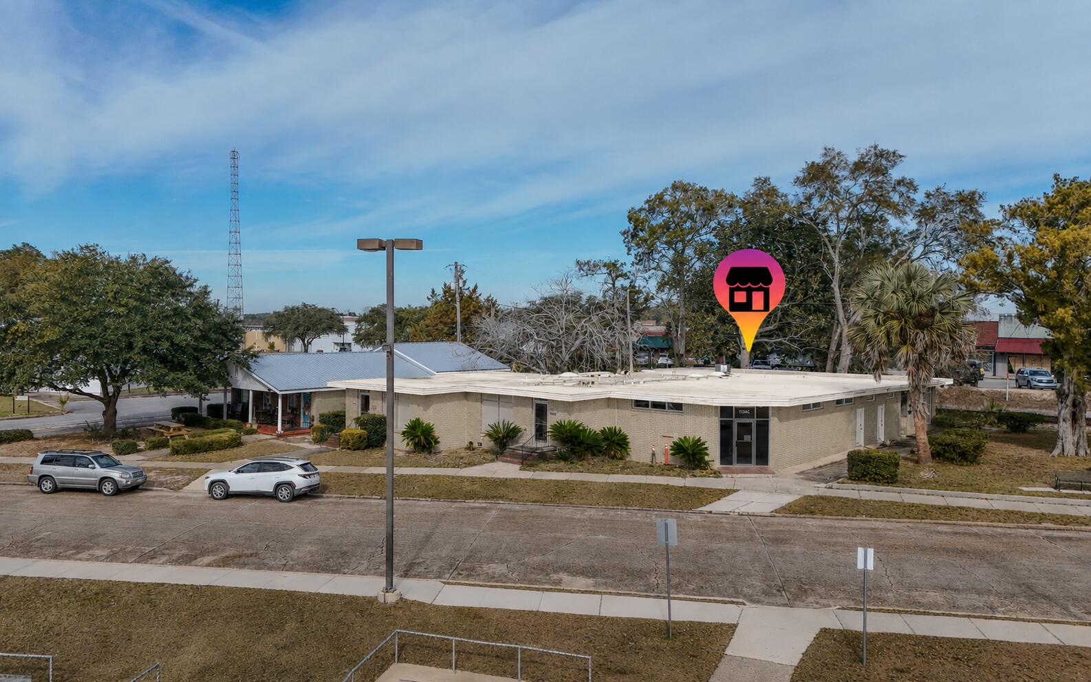 Rare downtown commercial lease in DeFuniak Springs, this spacious corner unit offers approximately 1,589SF with views of Lake DeFuniak. The well-planned layout includes a large reception area, four generously sized offices, two bathrooms, and a dedicated breakroom or kitchen area, making it an excellent fit for medical, physical therapy, counseling, aesthetics, wellness services, or professional care practices. The space is designed for smooth flow and functionality, allowing most users to operate with minimal modification. Natural light and a prominent corner presence enhance visibility in a vibrant downtown setting across from the lake and amphitheater. Exterior updates are underway, with refreshed photos coming soon. Tenant is responsible for utilities, internet and phone.