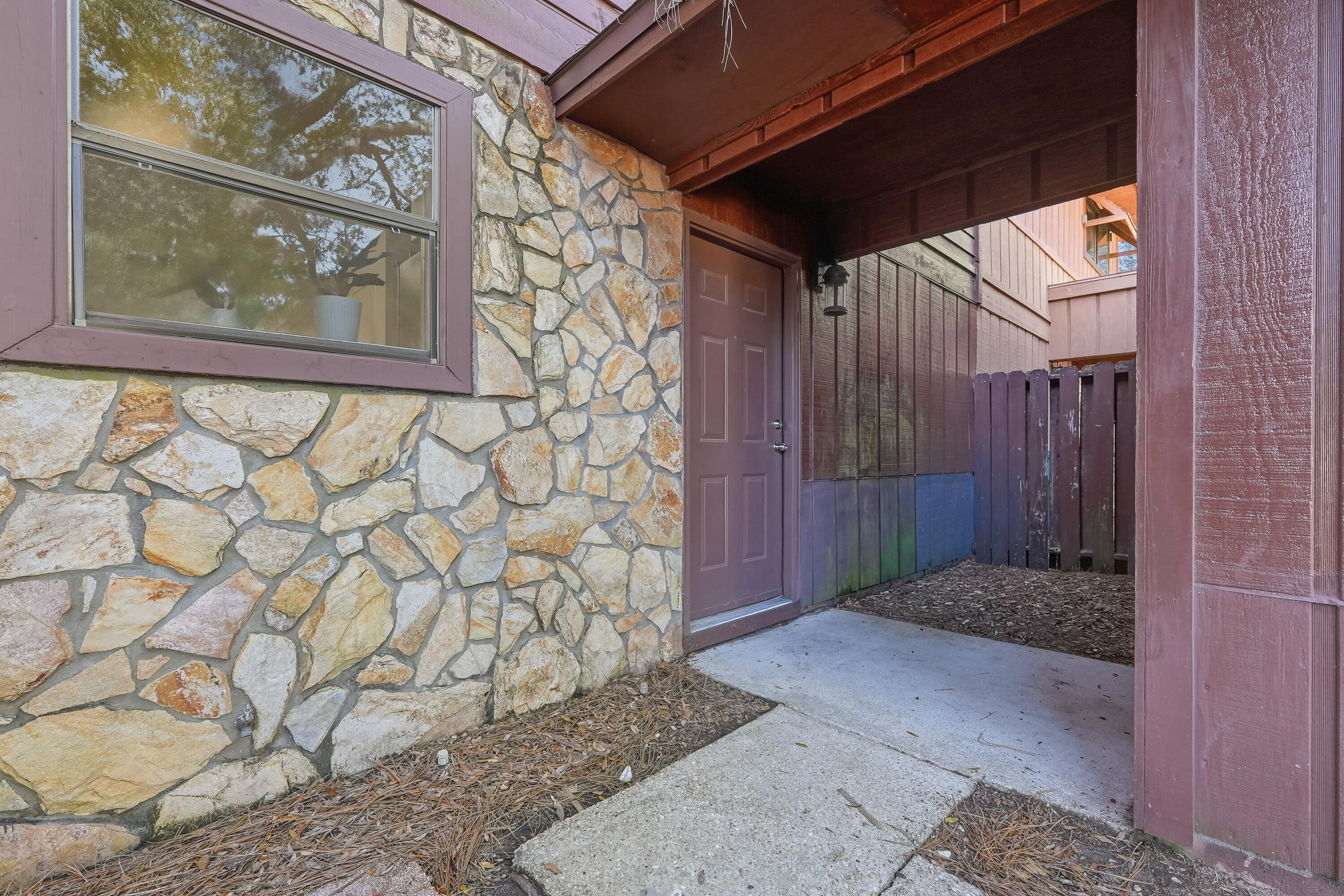 Tucked away on a quiet street just minutes from Eglin Air Force Base, this charming townhome with a garage offers both privacy and convenience. Spacious and thoughtfully updated, the home features an open living and dining area that flows seamlessly into a large kitchen. The kitchen shines with freshly painted white cabinetry, new countertops, a stylish metal backsplash, a pantry with wood shelving, and stainless-steel appliances. Enjoy peaceful outdoor living with a backyard that offers a woodsy feel, a patio for relaxing or entertaining, a partially replaced privacy fence, and a balcony off an upstairs bedroom. The attached garage is connected to the home by a covered walkway for added convenience. Move-in ready with major updates already completed: Brand-New Roof (2022). No HOA. A rare opportunity to own a well-updated, centrally located home in desirable Shalimar! Throughout the home, you'll find a freshly painted interior, updated doors, faucets, and sinks, and generous storage with wood shelving in all closets. Upstairs offers three comfortable bedrooms and two full bathrooms with updated countertops, while downstairs includes a convenient half bath and laundry room with added cabinetry. Attractive laminate wood flooring adds warmth and durability to the living spaces, creating a move-in-ready home perfect for military families, first-time buyers, or investors alike.