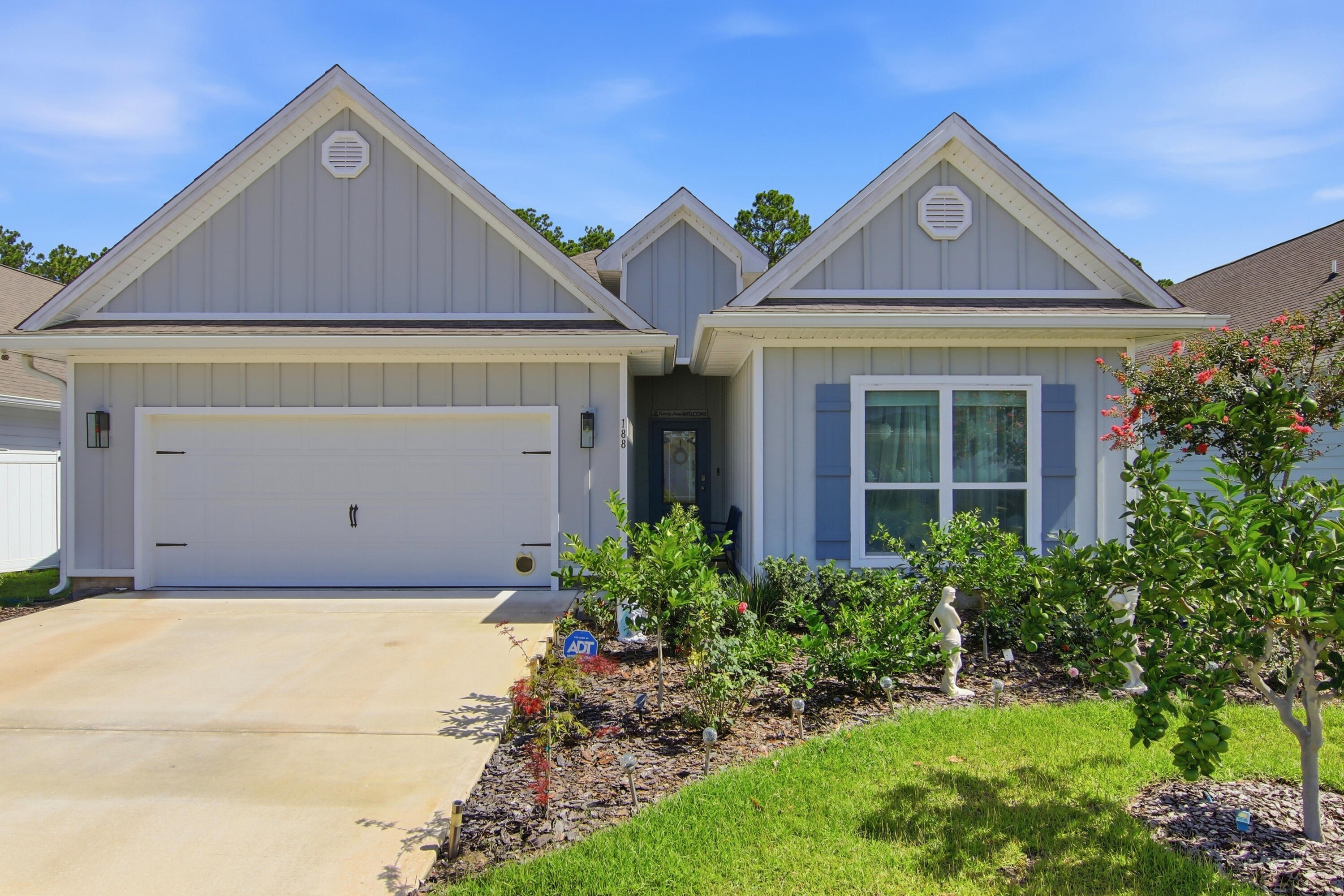 Imagine living just minutes from the sugar-white sands and emerald waters of Scenic 30A, with a backyard filled with fruit-producing citrus trees. Located less than four miles from public beach access, this beautifully maintained 4-bedroom, 3-bath home with a dedicated office features the sought-after Kennedy floor plan, offering the convenience of single-story living. Nestled in Walton's Landing, a short-term rental-friendly community, residents enjoy a community pool, scenic walking paths, tranquil ponds, and a central location. Inside, the open-concept design features vinyl plank flooring throughout, a spacious living area filled with natural light, and a beautifully appointed kitchen with quartz countertops, ivory shaker cabinetry, and ample prep space. 
The generous primary suite offers a large walk-in closet and a spa-inspired bath with a tiled shower and soaking tub. Additional upgrades include a security system with a doorbell camera, three exterior cameras, and upgraded ceiling fan fixtures in the bedrooms. Outside, the backyard is a true Florida retreat with more than 25 mature citrus trees - including kumquat, lemon, red navel orange, grapefruit, and mandarins-all currently producing fruit. Beautiful rose bushes enhance the front yard, while the screened-in covered porch with epoxy flooring provides the perfect place to relax and enjoy. The garage also features epoxy flooring, a whole-house water filtration system, along with a separate filtration system for the irrigation, allows you to enjoy fresh citrus right from your own trees. This home offers the perfect combination of coastal convenience and outdoor enjoyment. Seller is offering $3,000 towards the buyer's closing costs and/or prepaids.