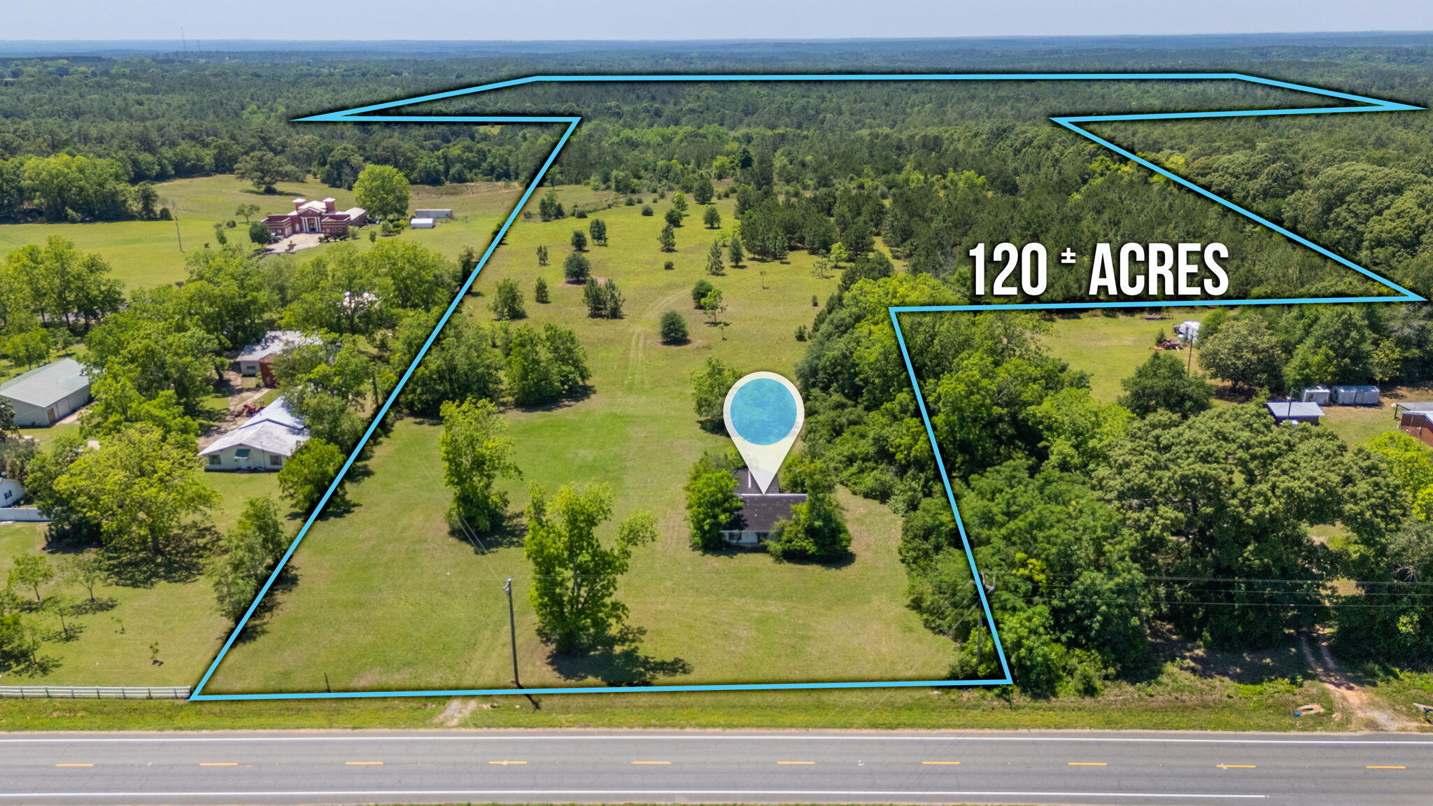 120± Acres | Development & Investment Opportunity | 5 Parcels Together | Hwy 85 Frontage

Rare opportunity to acquire approximately 120± acres comprised of five parcels with approximately 275 ft. of frontage along Highway 85 in growing North Okaloosa County. This unique property offers a combination of open land, mature timber, a creek corridor, & a small lake/pond feature located on the corner of the land.

The residential structure is 1911 sq. ft.  constructed in 1997; featuring 2 bedrooms, 2 bathrooms, garage, and a porch. The home is currently unoccupied and its condition is unknown. 

The property's expansive acreage, unique layout, natural features, and direct Highway 85 access offer exceptional versatility and potential for a variety of future uses. Whether envisioned as a residential development, private estate lots, family compound, farm, long-term land investment, or recreational hunting retreat, there are many possibilities to suit your vision.

Currently zoned RR with water available through Auburn Water System and electric on SR 85. Land and improvements are being sold AS-IS. Buyers are encouraged to conduct all inspections and due diligence to verify condition, zoning, land use, development feasibility, utilities, access, & intended use.

Conveniently located near Crestview, Duke Field Military base & the rapidly expanding Northwest Florida growth corridor, this property offers the perfect balance of accessibility, privacy, & rural charm.