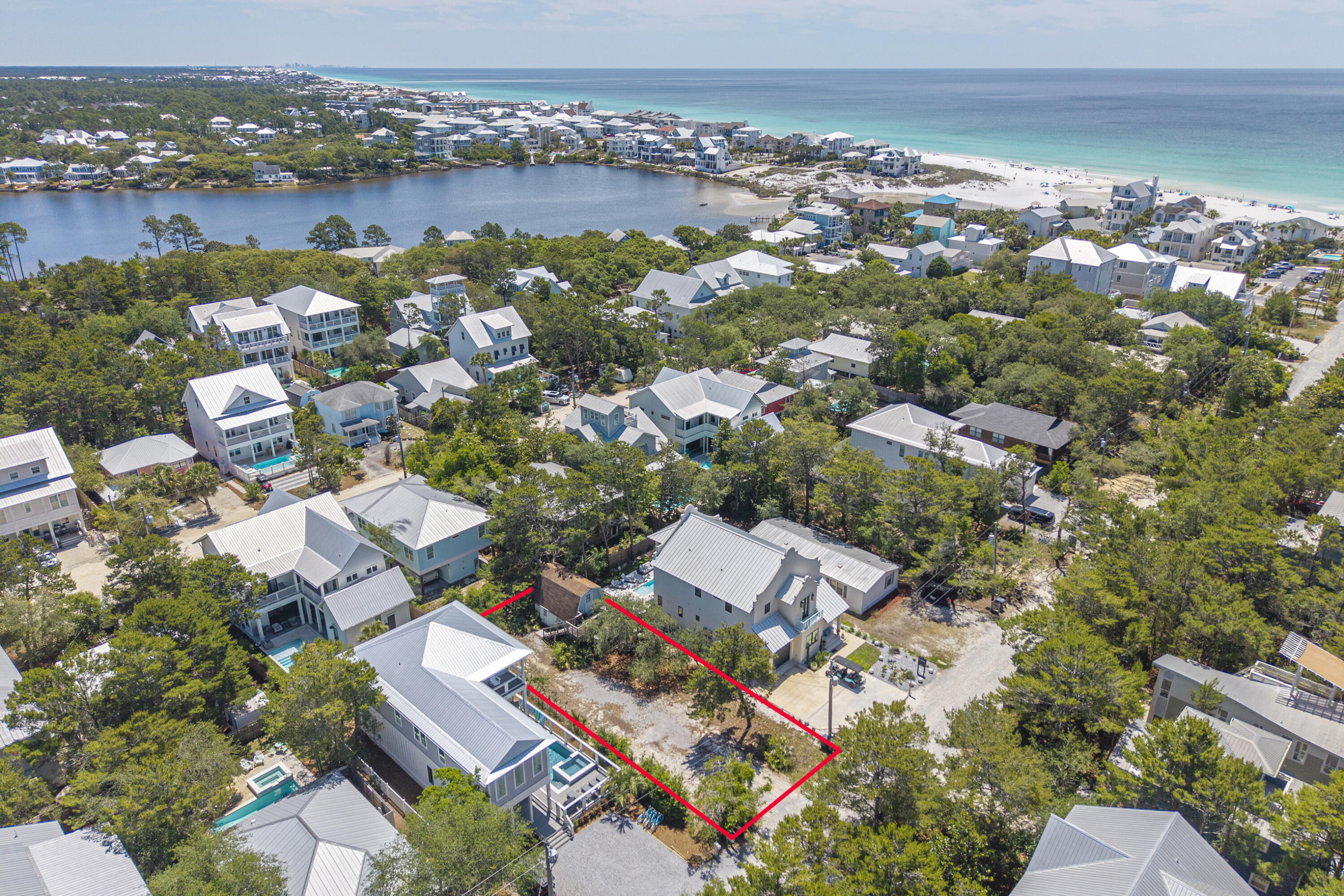 Rare opportunity to own a fantastic homesite south of 30A in the heart of Seagrove, just a few blocks from the Gulf and the beautiful shores of Eastern Lake. This 50x108 lot totaling approximately 0.12 acres is surrounded by luxurious homes and offers an exceptional setting to build your dream beach retreat in one of 30A's most desirable locations. Native oak trees create a charming Old Florida feel, while the easy gravel drive and peaceful setting enhance the property's appeal.
The property currently features an approximately 520 square foot structure with separate upper and lower level entrances, offering potential for restoration, guest quarters, pool house use, or an ADU conversion while planning a future build. The upper level includes a bedroom, bathroom, walk-in shower, and deck overlooking the trees, while the lower level offers concrete floors, wood ceilings, and a kitchenette. Ideally in Flood Zone X. 
Enjoy easy access to Eastern Lake, one of South Walton's rare coastal dune lakes with direct Gulf access, featuring a scenic boardwalk plus newer parking and bike parking conveniently located at the end of Williams Street off Eastern Lake Road. Paddleboard, boating, and fishing enthusiasts will love the convenient proximity to the nearby Eastern Lake Boat Launch. Perfectly positioned near Old Florida Fish House, Coastside 30A, Beachy Bean Coffee Co., Greenway Station, and the trails of Point Washington State Forest, this is an ideal spot to embrace the 30A lifestyle!