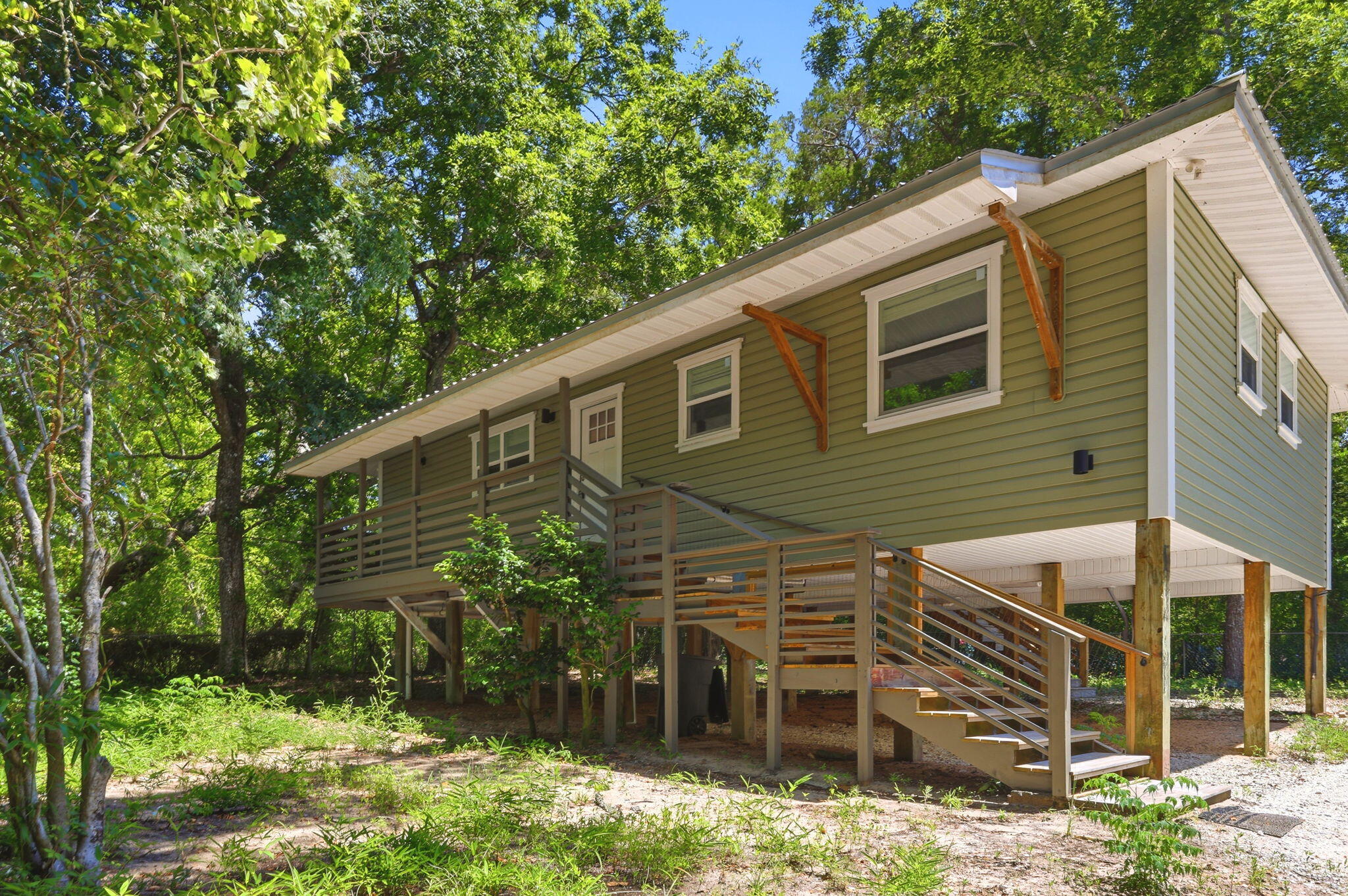 Welcome Home to 35 North Ave, Freeport. This 3-bedroom 2 bath home is located in the heart of Choctaw Beach. Completely renovated in 2023, renovations include new roof, siding, insulation, wiring, plumbing, fixtures, lights, flooring, windows, doors, AC, water heater, shaker cabinets, quarts countertops, completely remodeled bathrooms.
This charming home is nestled among mature trees and has plenty of room for gardening. This home blends country tranquility with the irresistible allure of waterfront proximity. The bay is just moments away and the serene country setting provides a peaceful retreat. It is only a short walk to the Choctaw Beach Park, with a boat launch. It is perfect for picnics, fishing, and stunning Choctawhatchee Bay views. 
The Choctaw Beach neighborhood is a hidden gem in the Florida Panhandle. This area offers exceptional value with convenient proximity to the beaches and attractions of the Emerald Coast.
The adjacent lot next-door may also be purchased if interested.