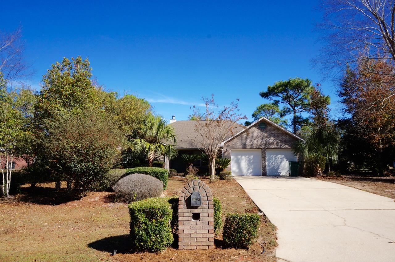 All Brick home in much sought after Hidden Creek, a sub area of Holley By The Sea. This 3 bed 2 bath home is situated on a spacious half acre lot w/greenbelt area across the street, providing a quiet serene location. The open floor plan offers wood flooring, wood burning fireplace w/mantle, built in book cases, formal dining area/flex space & cathedral ceiling. The kitchen boast 42'' upper cabinets, stainless appliances, refrigerator and hop up bar. The master suite has trey ceiling & upgraded bath w/slate tile shower, soaking tub w/tile surround, double vanities & lg. walk in closet. The spare bedrooms are very gracious in size as well. Enjoy the outdoors w/the large Florida Room and fenced back yard with mature trees & lush vegetation. The is a great price for a quality home so call toda