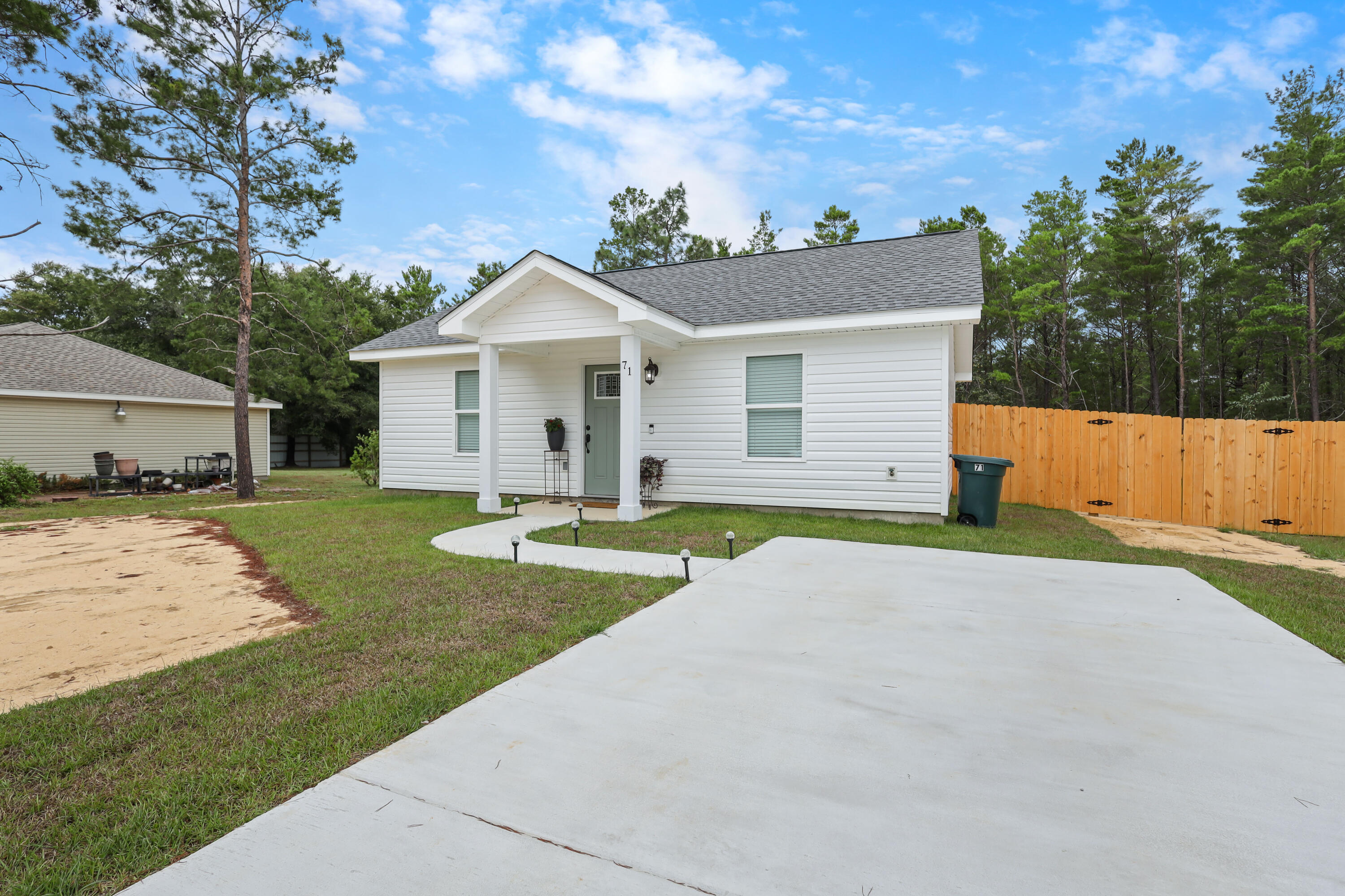 10% discount for active military! Step into this beautifully built 2-bedroom, 1-bath home featuring quality finishes and a thoughtfully designed layout. The open-concept kitchen, dining, and living area offers a comfortable space for everyday living, complete with shaker-style cabinets, quartz countertops, and stainless steel appliances. The modern bathroom features matching quartz surfaces and stylish brushed bronze fixtures. Enjoy a covered back porch overlooking a spacious backyard with lush green grass perfect for relaxing outdoors. A full-size washer and dryer are available if needed for added convenience. A $50 application fee applies