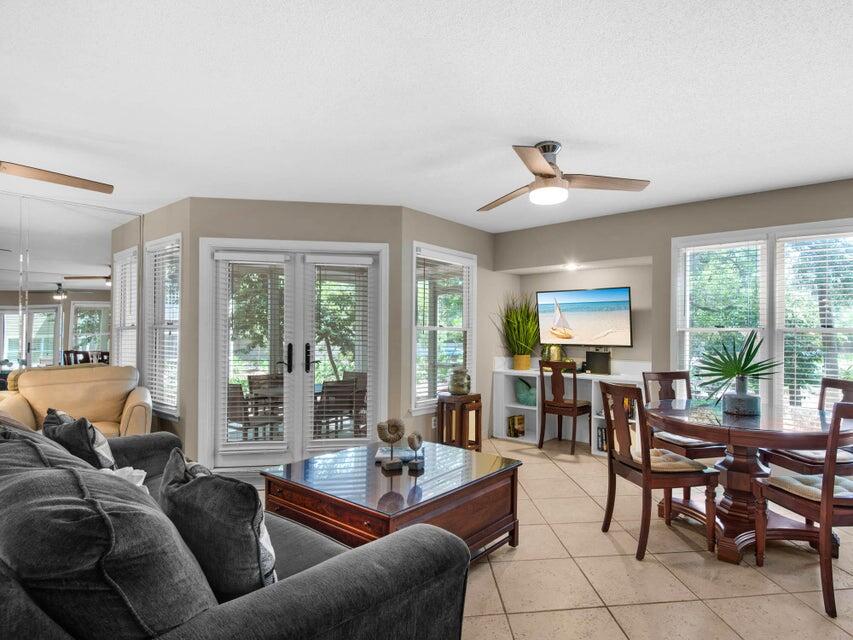 Tucked inside the beautifully wooded and highly sought-after Hidden Dunes community, this charming ground floor end-unit is the perfect coastal retreat. Surrounded by mature trees and lush landscaping, Hidden Dunes is known for its quiet, quaint feel--offering a peaceful escape while still being just steps from everything you love about the beach.

This one-bedroom, one-and-a-half bath condo offers over 800 square feet of comfortable living space, with a spacious primary suite and a queen sleeper sofa to accommodate guests. The open floor plan features a bright kitchen with a raised breakfast bar, tile flooring throughout, and a generous living area complete with a built-in desk, dining space, and cozy reading nook. Being sold fully furnished, it's truly move-in or rental ready. French doors lead to an oversized screened porch--one of the best spots to start your morning or unwind after a day in the sun. From here, you have easy access to the walking trails, the Beach & Racquet Club, and of course, the private beach access that makes Hidden Dunes so special.

Owners and guests enjoy a true resort-style experience with amenities that include multiple pools (with a heated option for cooler months), hot tubs, a playground, outdoor grilling areas, and a seasonal tram that makes trips to the beach effortless. The Beach & Racquet Club is a standout feature, offering tennis and pickleball in a beautifully maintained setting just moments from your door.

And the location? It's hard to beat. Situated south of Highway 98 with no roads to cross, you're just a short stroll or bike ride to the sugar-white sand beaches, as well as nearby dining, shopping, and entertainment. Sandestin, Scenic Gulf Drive, Silver Sands Outlet Mall, and 30A are all just minutes away.

Whether you're looking for a second home, investment property, or your own little slice of paradise, this Hidden Dunes gem offers the perfect blend of privacy, charm, and coastal convenience.

**NEW ROOF INSTALLED 2025. COMMUNITY REPAVED 2026. ALL SPECIAL ASSESSMENTS PAID IN FULL.**