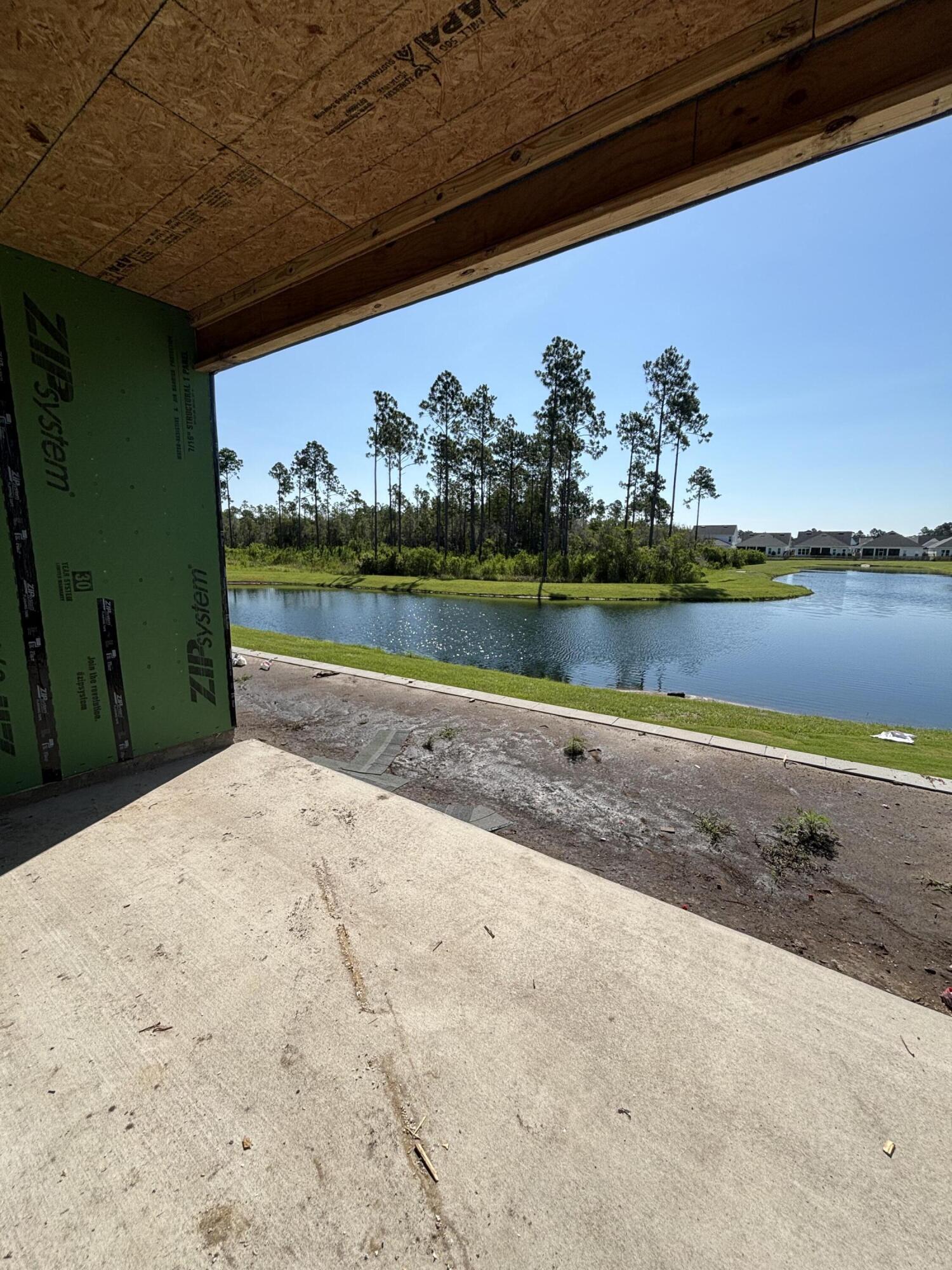 The Lucas plan offers 1,418 square feet, 2 bedrooms, 2 bathrooms, and a 1.5-car garage in the Villas at Longleaf Park within the Watersound Origins community. Positioned on a pie-shaped homesite overlooking a retention pond, the property combines low-maintenance living with outdoor space that includes a covered patio and privacy fencing. Estimated completion is Oct/Nov '26.

Designed with an open layout, the kitchen, dining, and family room connect seamlessly beneath 10-foot ceilings with 8-foot interior doors throughout. Large side windows and rear patio access bring natural light into the main living areas while maintaining a functional indoor-outdoor flow.

The kitchen includes upgraded soft-close cabinetry, Level 3 quartz countertops carried through the kitchen and bathrooms, an upgraded tile backsplash, walk-in pantry, and a GE appliance package with built-in appliances and a 5-burner gas cooktop. Luxury vinyl plank flooring extends throughout the home, complemented by craftsman-style trim and impact-rated windows.

The owner's suite includes a spacious walk-in closet and a bath finished with Level 3 quartz countertops . The guest bath features upgraded ceramic tile flooring and surround, while the secondary bedroom is positioned separately for added privacy and flexibility.

Additional features include a tankless water heater, gas grill rough-in, Smart Home package, irrigation system, and exterior lawn maintenance included for simplified ownership. Each residence is separated by a structurally independent 2-hour fire separation wall with insulated framing and layered gypsum board construction for added privacy and sound separation.

Located within Longleaf Park at Watersound Origins, the Villas offer convenient access to Watersound Town Center, Publix, dining, medical offices, Hwy 98, Village Commons, trails, and the Origins Golf Course.
