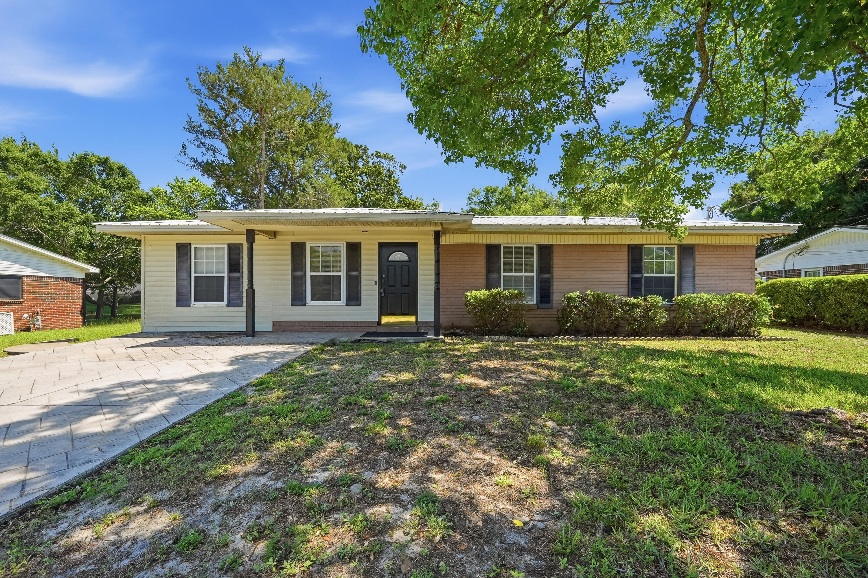 Location, location, location! This charming 3-bedroom, 1-bath home offers 1,314 square feet of comfortable living space and is conveniently located near shopping, schools, employment centers, and the beautiful Emerald Coast beaches.  The updated kitchen features granite countertops, stainless steel appliances, and refreshed cabinetry, creating a stylish and functional space for everyday living. Additional upgrades include insulated Pella windows and fresh interior paint in today's popular Sherwin-Williams color palette.  The former garage has been converted into a spacious family room, providing additional living and entertaining space. Outside, you'll find an oversized stamped concrete driveway and a large backyard with plenty of room to add a pool, outdoor living area, or garden. Whether you're looking for a primary residence, vacation home, or investment opportunity, this property offers an unbeatable combination of location, updates, and value.