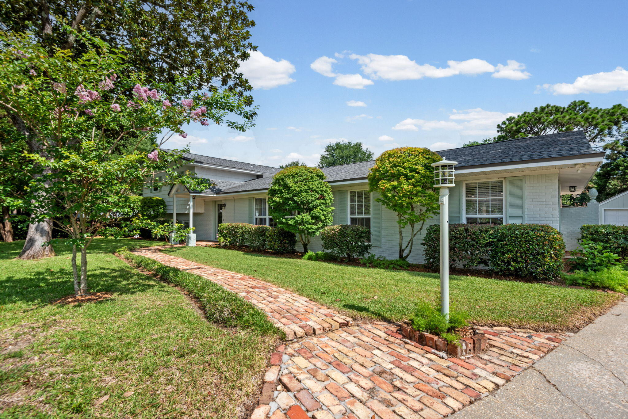Welcome home to 5 Maple Ave. an updated 3-bedroom,3 full bath home with a pool and large lot.
Nestled in the charming community of Poquito Bayou, and a 3-minute walk to the boat launch and park. This immaculate home has many upgrades and offers a private oasis complete with a large inground pool and private brick walls.
Enter through the front entry and discover two stunning living spaces each with a fireplace (1 gas and 1 electric). The main level includes entry, living room with electric fireplace, dining room, kitchen and a screened in Florida room
The large custom kitchen features upgraded cabinets, granite countertops, tile backsplash, newer appliances, dual ovens and a large pantry. The kitchen leads to a beautiful screened in porch that has been completely renovated, it is the perfect place to enjoy outdoor meals or entertain. The porch overlooks the sparkling in-ground pool and gardens that beckon you to relax in your own private oasis. A brick privacy fence surrounds the large backyard, ensuring seclusion while you enjoy the lush surroundings. 
Upstairs is the large primary suite and primary bath with a large custom closet and 2nd bedroom or office area and 2nd full bath.
The lower level has a large family room with a full wall brick gas fireplace, a full bath and private large 3rd bedroom.
In addition to the attached 2 car garage there is a separate detached garage  that could be converted into a pool house or work space. With its thoughtful design, attractive outdoor space, and convenient location, 5 Maple Ave delivers a comfortable lifestyle in one of the Emerald Coast's welcoming communities. Schedule a showing today.