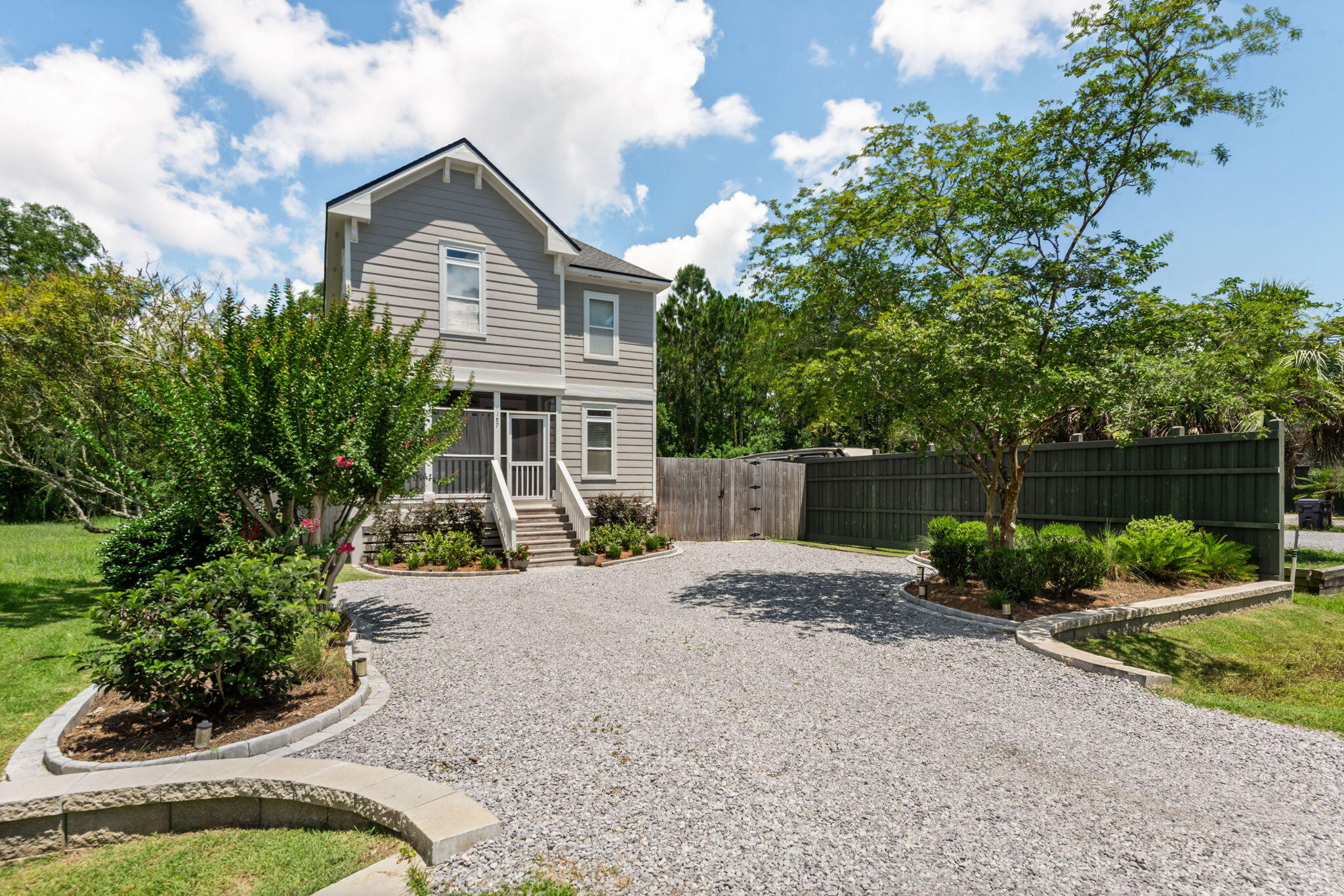 An elegantly crafted cottage, this two-story home in Santa Rosa Beach is a beautiful retreat.  Set on a newly landscaped lot with privacy fencing, it's just four miles to the Gulf of Mexico beaches and three minutes to Hogtown Bayou with bay access. New roof, new A/C, new hot water heater all in 2024.  Exterior recently professionally painted.  Stunning hardwood floors throughout much of home, high ceilings, crown molding, and custom cabinets are just some of the features. The front porch has wood ceiling, recessed lighting, fan, and breezy curtains to invite sitting. Transom windows let in natural light, custom kitchen cabinets and bronze fixtures add a cottage flair.  Extra storage behind walk-in master closet, and convenient walk-in attic space.  The second floor loft is quite large and can be used as an office, library or playroom. Hardie board exterior, wrap around deck from kitchen to back yard, plus storage shed.  Nearby Cessna Landing Park is within walking distance - offers boat ramp to Choctawhatchee Bay, fishing, basketball, picnic areas, playground, restrooms.  Walton County projects include an approved 10,000 seat amphitheater nearby with walking trails and event space.  Located near great shopping and dining on 30A, Grand Boulevard, Sandestin, Silver Sands Outlets, Destin and more. No HOA.
