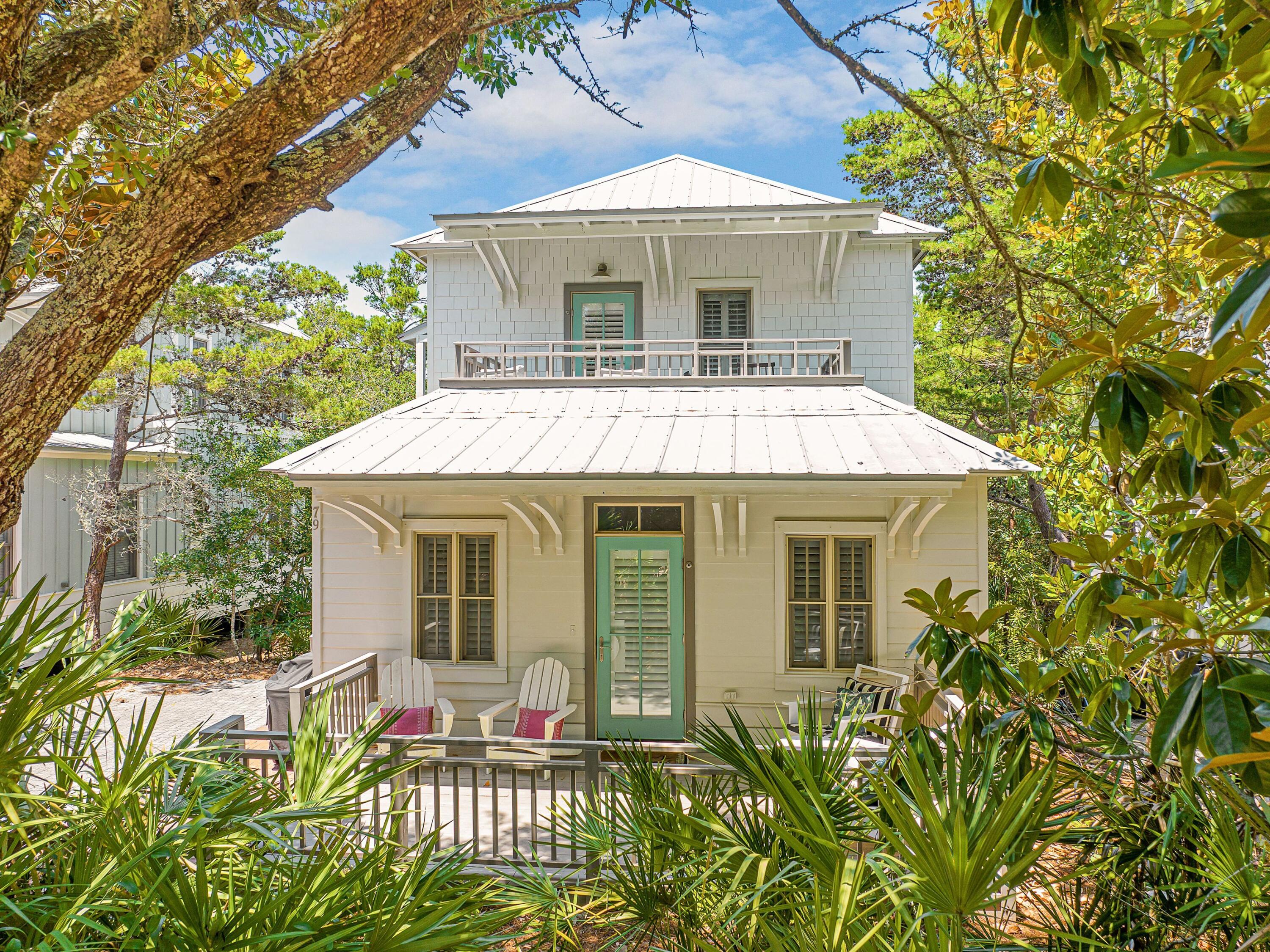 Inspired by the vibrant architecture of New Orleans' French Quarter and the iconic cabanas of Palm Beach, House of Palms offers a fresh, playful take on coastal living along 30A. Beautifully renovated and professionally furnished, this turnkey retreat is located less than 800 feet from the deeded beach access and less than two miles from Rosemary Beach and several of the area's beloved town centers, placing dining, shopping and entertainment just moments away.

Designed to accommodate both everyday living and memorable vacations, the home has been thoughtfully updated with shiplap throughout, all-new bathrooms, stylish furnishings and an enhanced front porch that sets the tone for the experience within. Already established on a successful rental program, the property has been carefully appointed to meet the expectations of today's vacation guests while maintaining the comfort and character owners appreciate.

The first floor features three spacious bedroom suites, each with its own private bath. Two king suites provide comfortable accommodations for adults, while a custom-built queen-over-queen bunk room creates an ideal gathering space for younger guests. An additional bunk nook provides additional sleeping capacity, allowing the home to comfortably host up to 10 guests.

On the second floor, vaulted ceilings and abundant natural light highlight the open-concept living, dining and kitchen areas. The well-appointed kitchen features KitchenAid stainless steel appliances and  ample seating, while the adjoining living spaces create a natural setting for entertaining, relaxing and reconnecting after a day at the beach. Three generous porches expand the home's living space outdoors, offering inviting spots for morning coffee, alfresco dining and evening conversations in the coastal air.

Owners and guests enjoy access to deeded beach access and a community pool, making it easy to spend the day on the sugar-white sand or cool off close to home. A neighborhood provisions shop adds convenience for everything from beach essentials to a bottle of wine for sunset gatherings. Situated in the charming 30A town of Seacrest, between Watersound and Alys Beach, it's best known for its beautiful beaches, terrific restaurants, farmers markets, and more for the quintessential coastal experience.

Combining distinctive design, proven rental performance and an exceptional location along Scenic Highway 30A, House of Palms presents an outstanding opportunity to enjoy the best of Emerald Coast living.