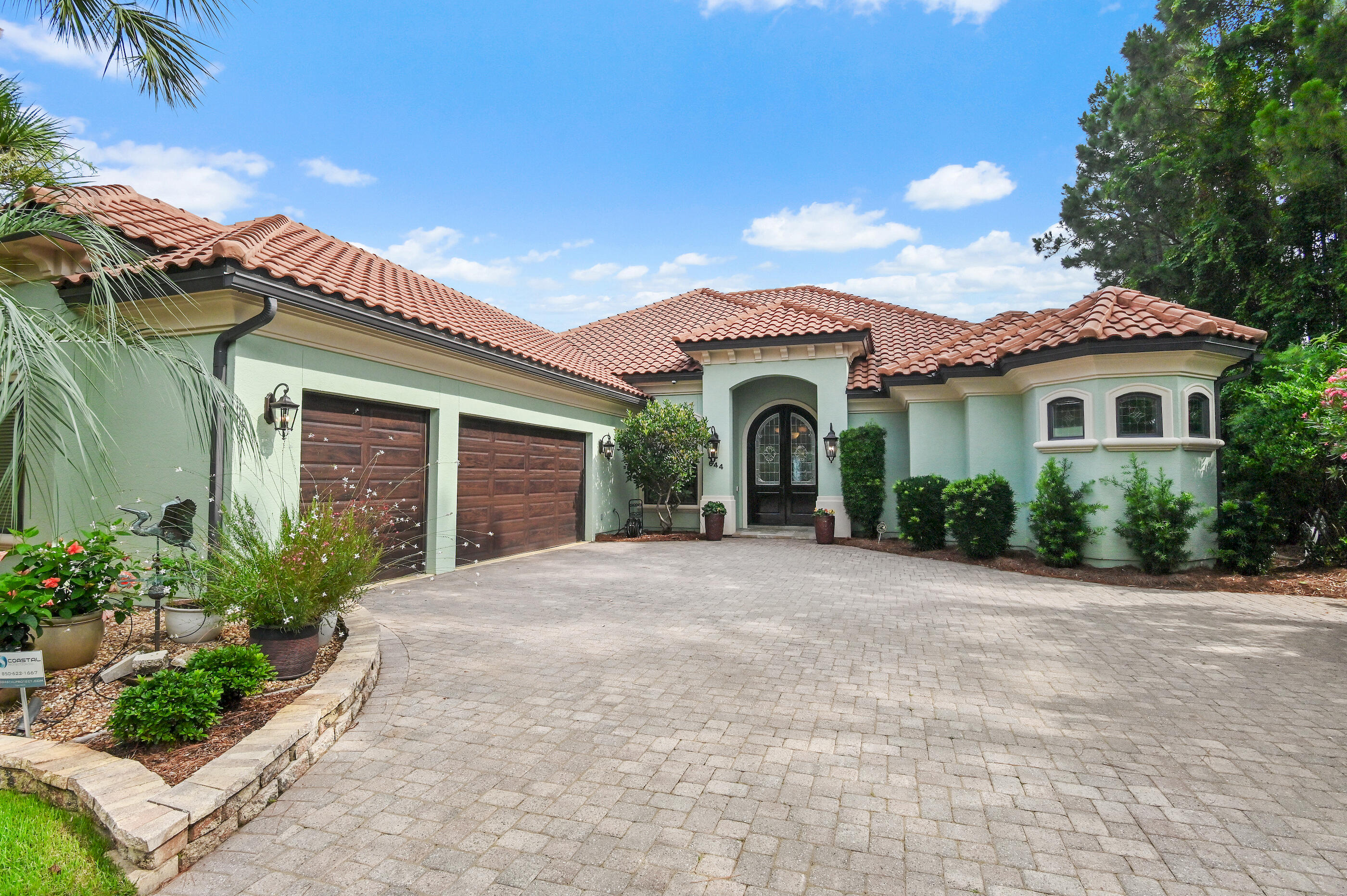 This stunning single-story home captivates with exquisite and impressive features along with unparalleled convenience. Custom-built by award-winning Dixon Kazek Construction (DKM Custom Homes), no detail has been overlooked. Features include hardwood and tile flooring, 10-12 foot ceilings, crown molding, custom cabinets, granite counters, stainless steel appliances, Anderson windows and doors, and solid building practices. Inside the mahogany double front doors, a welcoming foyer opens to a formal living area with beckoning Bay views, guiding you toward the gourmet kitchen and great room. Beyond that, a perfect waterfront office or fourth bedroom awaits. Guest bedrooms with private baths are on the west side of the home, while the master retreat is on the opposite side. This spacious bedroom includes a cozy fireplace and a private sliding glass entry to the screened lanai area. The spa-like master bath features a tremendous walk-in closet, dual vanities with granite counters, a Microbubble freestanding tub, and an immense walk-in tile shower with body sprays, and a rain head shower. Lush tropical landscaping with dusk-to-dawn lighting accentuates your evening views. Enjoy waterfront living from your private dock or screened lanai with a heated salt water pool (remote control), illuminated waterfall, fireplace, and a summer kitchen complete with a stainless grill, prep sink, and ice maker. This Bayshore Drive location is ideal, with no Homeowners Association, and is just minutes by boat to Sandestin's Baytowne Wharf or Destin's Crab Island, Harbor, East Pass, and the Gulf. Be at a prime golf course in 5 minutes or sink your toes in the sugar-white sand within 8. First-class shopping and dining are also within close proximity. This home has been meticulously loved and maintained and this opportunity simply won't last!
