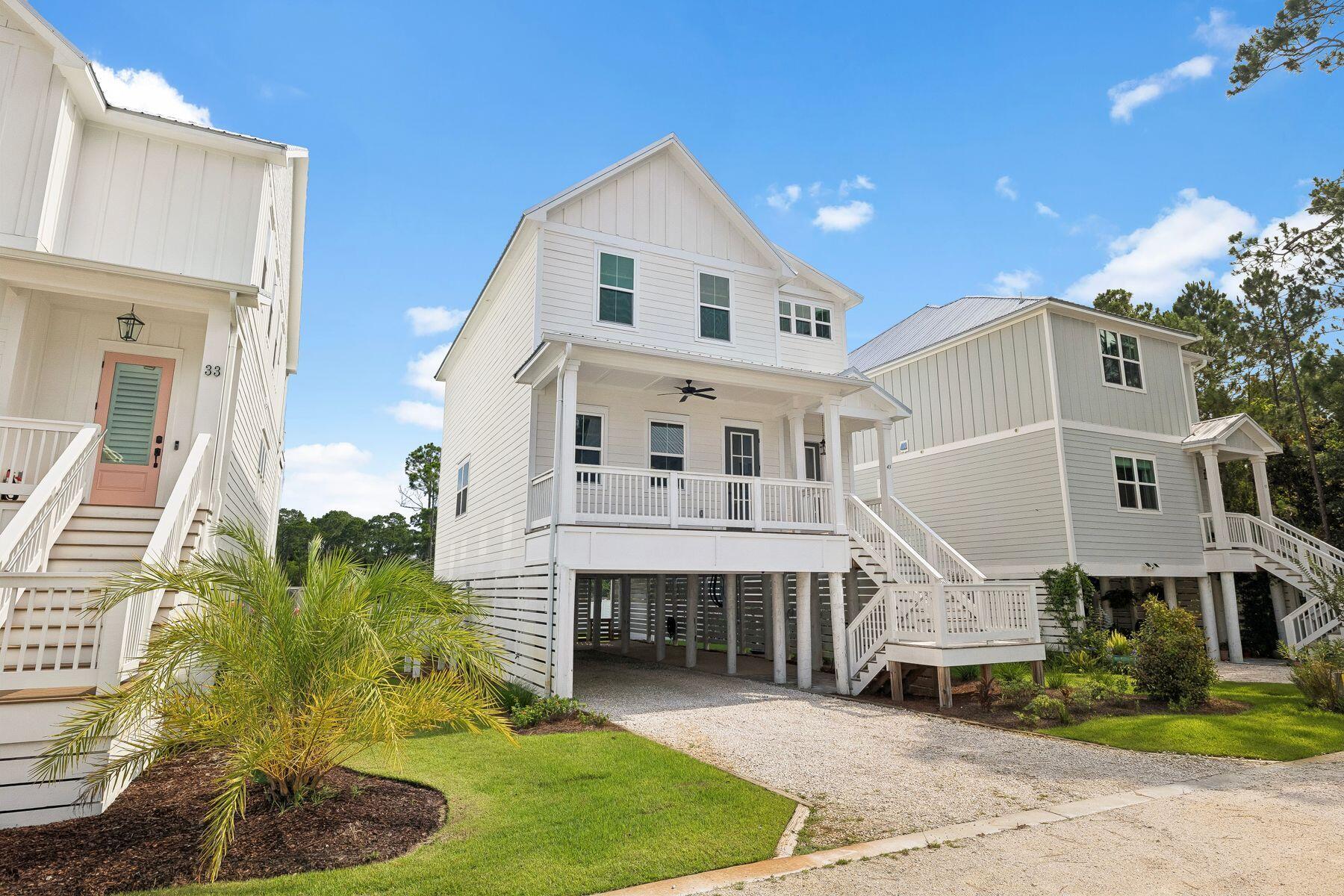Beautiful waterfront home on Mill Bayou offering breathtaking bay views and the perfect blend of coastal charm and modern convenience. Built in 2023 and impeccably maintained, this 3-bedroom, 2.5-bath Florida cottage feels like new.

The open-concept floor plan features beautiful flooring, crown molding, and a bright, inviting kitchen with a center island designed for effortless entertaining. Upstairs, you'll find all three bedrooms along with a conveniently located laundry area.

Step outside to the spacious covered back deck and unwind while taking in spectacular sunset views over the bay, or enjoy fishing, kayaking, and paddleboarding from your private dock.

Located directly across from Cessna Landing County Park, you'll have immediate access to a public boat launch, making it easy to explore Choctawhatchee Bay and the surrounding waterways by boat. When it's time for the beach, Ed Walline Regional Beach Access on 30A is approximately 3.6 miles away--just one left turn down County Highway 393 to the sugar-white sand and emerald Gulf waters. Supplemental boat storage available nearby.

Additional features include a covered carport, natural gas, a tankless water heater, and an unbeatable location. Whether you're searching for a primary residence, second home, or investment property, this exceptional waterfront retreat offers the very best of the Florida lifestyle.  

All square footage and room dimensions are approximate and should be verified by the buyer.