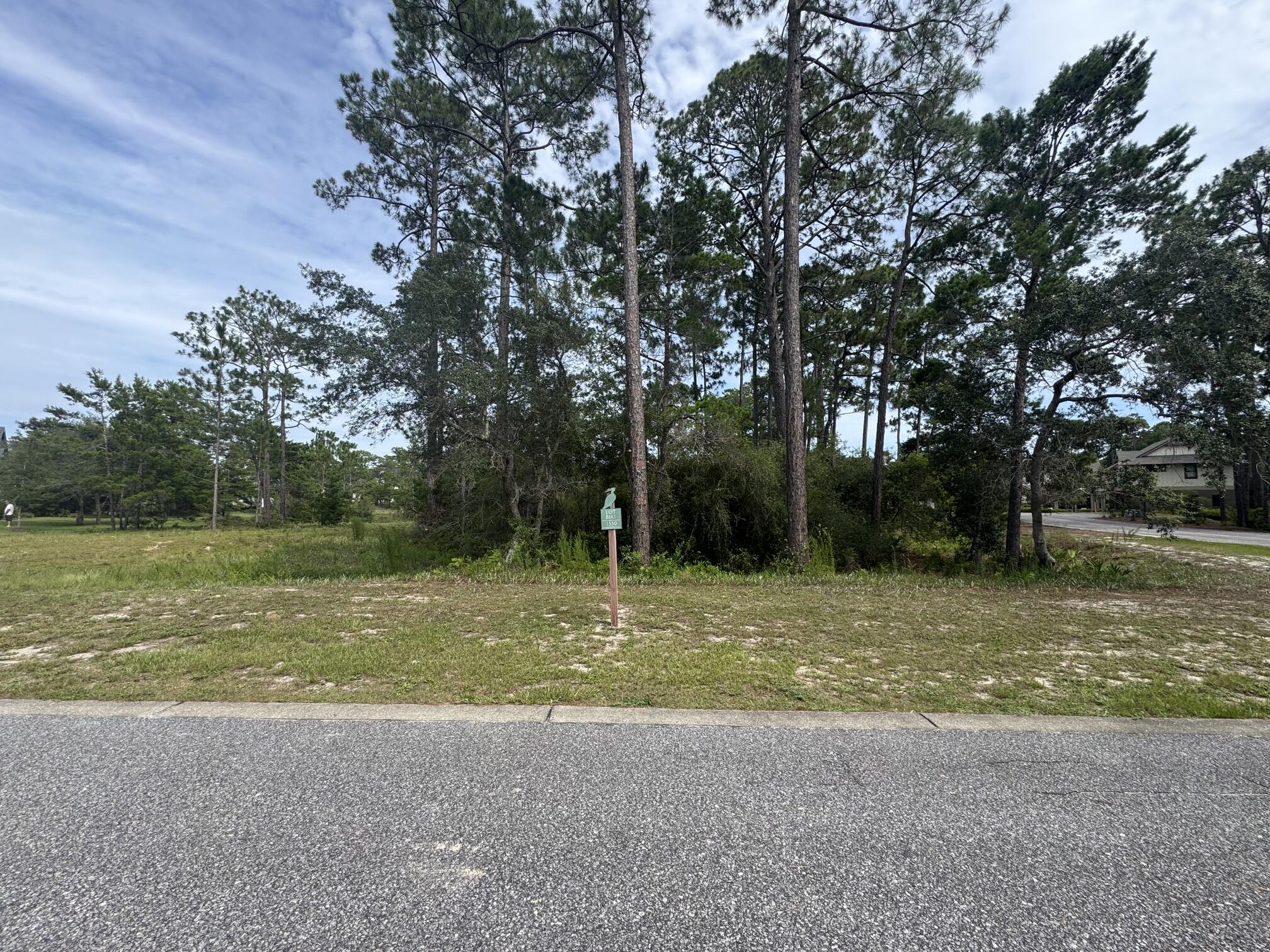 Best Priced Lot in Wild Heron! This prime location, situated along Sharks Tooth Trail, presents an ideal opportunity for the construction of a residence featuring a distinctive circular driveway on this corner lot.

It is easy to envision a dream home emerging within this setting, complete with inviting outdoor spaces for relaxation and entertainment. 

The Wild Heron neighborhood is distinguished by its exceptional amenities, including a beautifully designed swimming pool, scenic walking trails, and a thoughtfully integrated golf course. These features facilitate an engaging community where residents can partake in social events and cultivate lasting relationships.