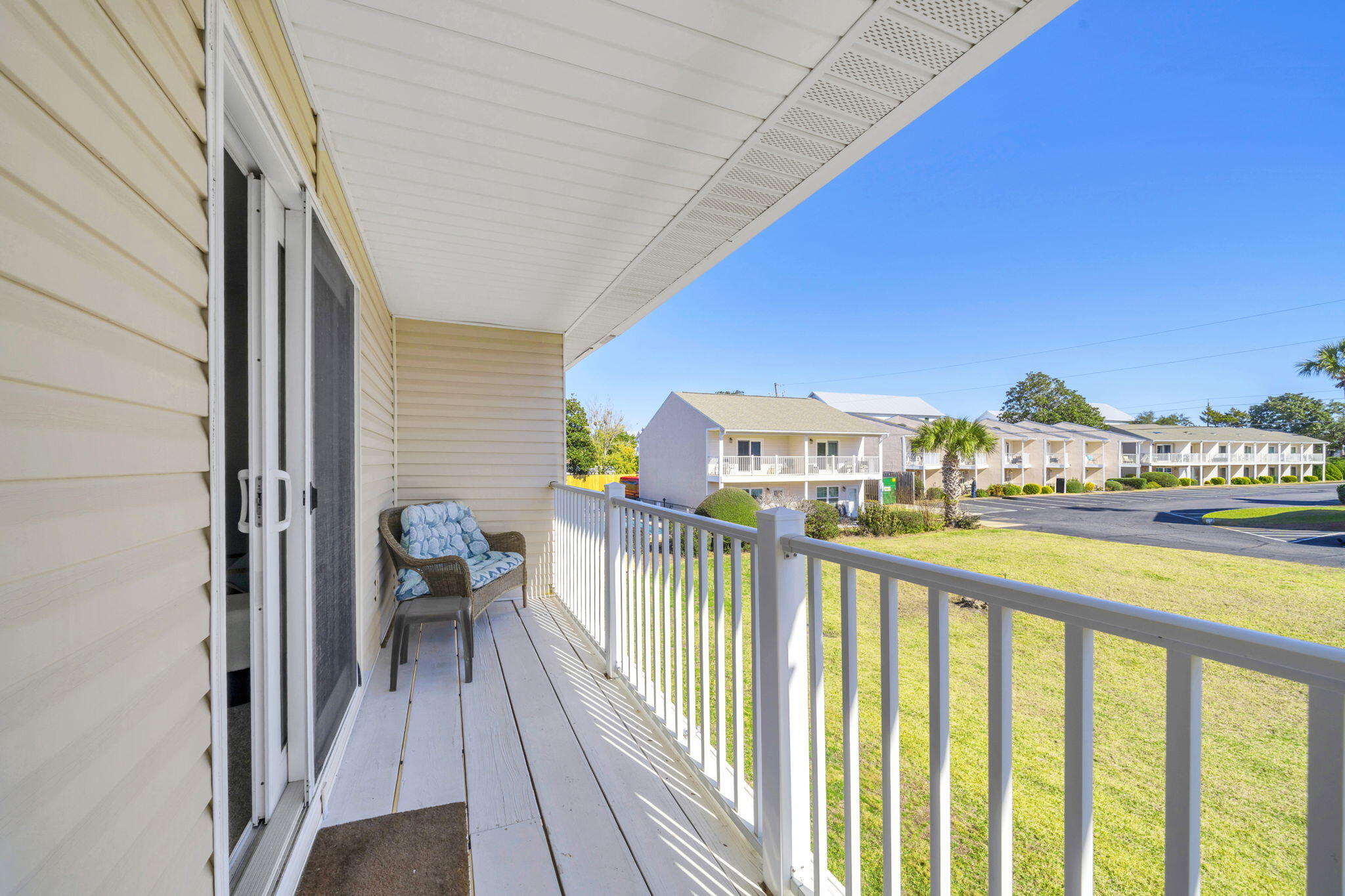 Projected short term rental potential of approximately $50,000 annually makes this Miramar Beach townhome a strong opportunity for investors or buyers seeking a beach home with income potential.

Located just a short walk to the beach in Miramar Beach, Florida, this fully furnished 2 bedroom, 2.5 bathroom townhome offers the flexibility of a primary residence, vacation home, or short term rental property along the Emerald Coast.

The location provides quick access to the sugar white sand beaches and emerald green waters of the Gulf of Mexico, allowing you to easily walk to the beach without the hassle of parking.  Nearby attractions include Pompano Joe's, Silver Sands Premium Outlets, grocery stores, restaurants, and entertainment, placing you in the heart of one of the most desirable Destin and Miramar Beach areas.

Inside, the home features a bright open concept living area with tile flooring throughout the main level. The living room flows seamlessly into the dining space and kitchen, creating a comfortable layout ideal for both everyday living and vacation rentals.

The kitchen is equipped with white cabinetry, granite countertops, stainless steel appliances, a breakfast bar, and ample storage. A convenient half bathroom is located on the main level for guests.

Upstairs, both bedrooms are spacious and privately situated, each with its own full bathroom to provide comfort and privacy for owners and guests. The bedrooms feature blackout curtains, and the home includes a full laundry area for added convenience.

Two assigned parking spaces are located directly in front of the unit for easy access. The property also includes a large outdoor storage area and a separate interior owner's closet, perfect for storing personal belongings and rental supplies.

Relax on the covered balcony overlooking the surrounding green space, an ideal spot for morning coffee or evening relaxation after a day at the beach.

The Woodland Shores community offers two pools, a clubhouse, and shared outdoor areas, adding to the resort style amenities.
Short term rentals are allowed, and with the home being sold fully furnished, this property offers a turnkey beach investment opportunity in Miramar Beach near Destin and Scenic Highway 30A.

Buyer to verify all dimensions.